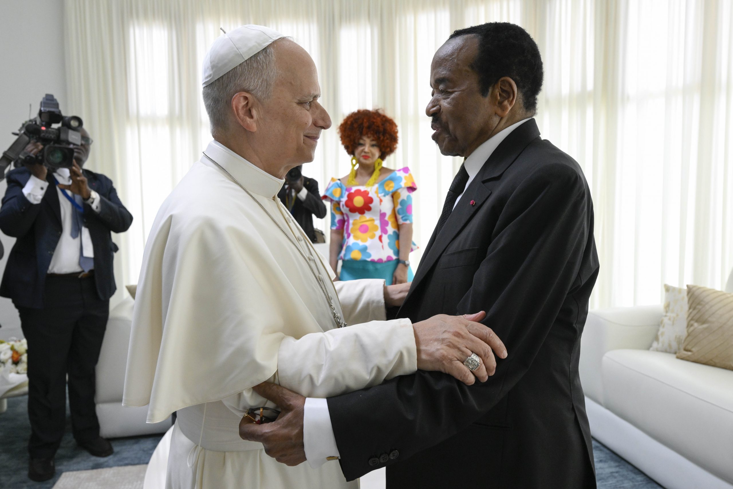 PHOTOS: Pope Leo XIV departs Cameroon, journeys to Angola – #Catholic – Pope Leo XIV continued his apostolic journey in Africa on April 18, saying Holy Mass in Cameroon before departing for Angola on the next leg of his visit. The Holy Father will spend several days in Angola before finishing his trip in Equatorial Guinea. This is his first papal trip to the continent. Here are some of the highlights of Pope Leoʼs latest activities during his trip:
 
 Pope Leo XIV waves to Catholics while at Yaoundé-Ville Airport to say Holy Mass, Cameroon, Saturday, April 18, 2026. | Credit: Vatican Media
 

 
 Catholics smile and wave during a papal Holy Mass at Yaoundé-Ville Airport in Cameroon, Saturday, April 18, 2026. | Credit: Vatican Media
 

 
 Pope Leo XIV waves to Catholics during Holy Mass at Yaoundé-Ville Airport in Cameroon, Saturday, April 18, 2026. | Credit: Vatican Media
 

 
 Pope Leo XIV poses with Catholics at Holy Mass at Yaoundé-Ville Airport in Cameroon, Saturday, April 18, 2026. | Credit: Vatican Media
 

 
 Pope Leo XIV greets Catholics during Holy Mass at Yaoundé-Ville Airport in Cameroon, Saturday, April 18, 2026. | Credit: Vatican Media
 

 
 Pope Leo XIV greets Archbishop of Yaoundé Monsignor Jean Mbarga during Holy Mass at Yaoundé-Ville Airport in Cameroon, Saturday, April 18, 2026. | Credit: Vatican Media
 

 
 Pope Leo XIV holds a baby while at Yaoundé-Ville Airport to say Mass in Cameroon, Saturday, April 18, 2026. | Credit: Vatican Media
 

 
 Pope Leo XIV views a farewell ceremony at Yaoundé-Nsimalen International Airport in Cameroon, Saturday, April 18, 2026. | Credit: Vatican Media
 

 
 Pope Leo XIV speaks to journalists aboard the papal plane en route to Quatro de Fevereiro Airport in Luanda, Angola, Saturday, April 18, 2026. | Credit: Vatican Media
 

 
 Pope Leo XIV deboards the papal plane at Quatro de Fevereiro Airport in Luanda, Angola, Saturday, April 18, 2026. | Credit: Vatican Media
 

 
 Pope Leo XIV receives a ceremonial greeting upon his arrival at Quatro de Fevereiro Airport in Luanda, Angola, Saturday, April 18, 2026. | Credit: Vatican Media
 

 
 Pope Leo XIV receives a ceremonial greeting upon his arrival at Quatro de Fevereiro Airport in Luanda, Angola, Saturday, April 18, 2026. | Credit: Vatican Media
 

 
 Pope Leo XIV receives flowers upon his arrival at Quatro de Fevereiro Airport in Luanda, Angola, Saturday, April 18, 2026. | Credit: Vatican Media
 

 
 Pope Leo XIV meets with Angolan President João Manuel Gonçalves Lourenço in Luanda, Saturday, April 18, 2026. | Credit: Vatican Media
 

 
 Pope Leo XIV meets with Angolan President João Manuel Gonçalves Lourenço in Luanda, Saturday, April 18, 2026. | Credit: Vatican Media
 

 
 Pope Leo XIV and Angolan President João Manuel Gonçalves Lourenço speak in Luanda, Saturday, April 18, 2026. | Credit: Vatican Media
 

 
 Pope Leo XIV sits during a meeting with government officials and civil leaders in Luanda, Angola, Saturday, April 18, 2026. | Credit: Vatican Media
 

 
 Pope Leo XIV shakes hands with Angolan President João Manuel Gonçalves Lourenço during a meeting with government officials and civil leaders in Luanda, Angola, Saturday, April 18, 2026. | Credit: Vatican Media
 

 
 Pope Leo XIV speaks to government officials and civil leaders in Luanda, Angola, Saturday, April 18, 2026. | Credit: Vatican Media
 

 
 Pope Leo XIV speaks to Angolan President João Manuel Gonçalves Lourenço during a meeting with government officials and civil leaders in Luanda, Angola, Saturday, April 18, 2026. | Credit: Vatican Media
 

 
 Pope Leo XIV greets a child in Luanda, Angola, Saturday, April 18, 2026. | Credit: Vatican Media