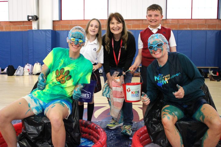 Sparta school raises more than K for youth heart health #Catholic – Rev. George A. Brown Memorial School in Sparta, N.J., raised ,000.57 for the American Heart Association through its annual Jump Rope for Heart/Kids Heart Challenge, far surpassing this year’s goal of ,000.
The school celebrated the milestone as students gathered for a morning assembly to watch Principal Patricia Klebez and Physical Education Teacher Ashley DiGidio get slimed — a promised reward for reaching the fundraising goal. The event brought excitement and laughter while highlighting the school community’s dedication to a meaningful cause.
For nearly two decades, Rev. Brown has supported heart health initiatives through this annual program, which was introduced in 2006 by former physical education teacher Lori Wehmeyer who is now one of the development directors of School Engagement for the American Heart Association for some of the local schools in New Jersey. Since then, the school community has raised more than 0,000 to support the American Heart Association’s mission to fight heart disease and promote healthier lives.
“The Kids Heart Challenge allows students to learn how to take care of their hearts, bodies, and minds while helping children their age who have special heart conditions,” said Ashley DiGidio, current physical education teacher and event organizer. “Through activities like ‘Finn’s Mission,’ students even learn the steps of Hands-Only CPR.”
The program transforms the school gym into an interactive and engaging space filled with activity stations, including jump rope, skip-it, and knockout competitions. Students eagerly anticipate the event each year, often asking about it months in advance.
DiGidio noted that one of her favorite aspects of the fundraiser is tracking weekly progress and seeing students grow both physically and emotionally. “It’s exciting to watch their skills improve and to see their enthusiasm for helping others,” she said.
The idea to incorporate the slime incentive came from DiGidio, inspired by encouragement from Wehmeyer over the years. After announcing the challenge during a school assembly, the community quickly rallied—reaching the ,000 goal within a day and ultimately climbing to over ,000 by week’s end.
Reflecting on the final total, Klebez shared, “At first, I was in disbelief. This is the largest amount we’ve ever raised. But the Rev. Brown community always rises to the occasion. From Stuff the Stocking to the recent O.S.C.A.R. collection, and now Jump Rope for Heart, we continue to show what it means to support those in need while teaching our students the importance of social justice and service.”
Klebez described the sliming experience as “warm, gooey, and a little gross—but absolutely worth it,” adding that she would gladly do it again, though future events may involve additional staff participants.
“There is not a day that goes by that I am not proud of this school community,” Klebez said. “The students, staff, and parents are shining examples of what it means to truly walk in Christ’s footsteps.”
With another successful year complete, anticipation is already building for next year’s Kids Heart Challenge. While details remain under wraps, one thing is certain: the Reverend Brown community will once again rise to meet the challenge.