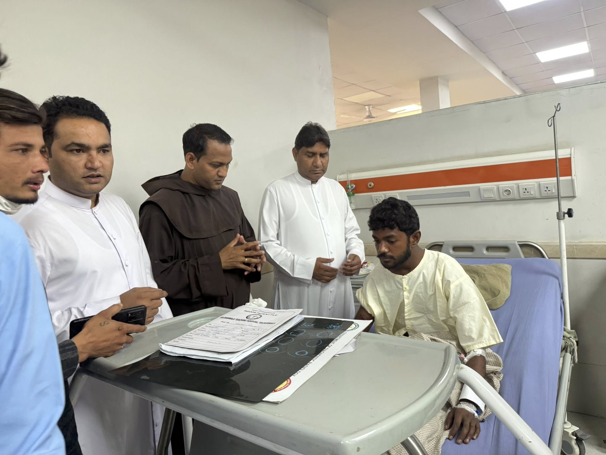 Teen killed, 60 hurt after truck rams Easter procession in Pakistan – #Catholic – LAHORE, Pakistan — Police in Pakistan are continuing their search for a driver who fled after a truck rammed into an Easter procession, killing a teenage boy and injuring more than 60 people, as concerns grow over accountability and safety lapses four days after the incident.The crash occurred in the early hours of April 5 in Mariamabad in Punjab’s Wazirabad district, where around 200 Catholics had gathered for a predawn Easter service. Irfan Bashir, a 17-year-old laborer, died of a head injury on April 6.Officials said the suspect, identified as Muhammad Bilal, remains at large. The vehicle involved in the incident and the driver’s assistant are in police custody, and a case has been registered.“We are conducting daily raids to arrest the driver,” said Muhammad Ahmad, the assistant sub-inspector who filed the case, attributing the incident to overspeeding.He added that the vehicle was empty and heading to a poultry farm and claimed the procession was held without prior police notification.At least 14 injured remain hospitalized in two hospitals in nearby Gujranwala, some in serious condition. Doctors said most victims suffered fractures and trauma caused by the impact and the ensuing panic.The Punjab government set up a medical camp at the local Catholic church on April 6 to assist victims in Mariamabad, a village of about 100 families comprising both Christians and Muslims.Disputed claimsChurch representatives and community members have disputed police claims that authorities were not informed in advance. Organizers insist prior notice had been given, raising concerns over coordination failures.Father Shahrukh Nathaniel, who led the sunrise service, said road processions have now been suspended following the tragedy.“We have asked the government to install speed breakers [in some countries called speed bumps] and barriers outside the church, which is located on a main road,” he told EWTN News. “The faithful usually gather outside after Mass, which increases the risk.”He said authorities have promised financial compensation for the victims and praised the establishment of a medical camp amid shortages in government hospitals, while urging the swift arrest of the driver.‘It was the worst Easter’Among the injured is the father of Mark Mathew, a ninth-grade student who was setting off fireworks at the front of the procession when the truck struck. His father, a furniture maker, suffered a fractured leg and is bedridden, while his mother sustained injuries to her knee and eye.“I feel lucky to be alive,” Mark said. “It was the worst Easter, visiting injured relatives and friends in hospitals.”Rights advocates say the case highlights broader concerns over the safety of minority religious gatherings in Pakistan.Capuchin friar condemns ‘Christianophobia’In an April 8 statement, Capuchin Father Lazar Aslam, convener of the Justice, Peace, and Ecology Commission, “vehemently condemned this irresponsible and heinous act,” describing it as a “clear Christianophobia-driven hate crime.”“This was not a mere traffic accident; it was a targeted assault on innocent worshippers at the most sacred moment of their liturgical calendar,” he said. “The driver’s failure to stop or render aid, and his decision to flee the scene, further underscores the malicious nature of this crime.”He added that “the persistent silence and minimization of such incidents are as painful as the violence itself,” warning that genuine interfaith dialogue cannot exist without truth and safety.“Until the lives of Christians are treated with equal dignity and those responsible are held accountable, empty words of peace will remain insufficient to heal the wounds of the community,” he said.Aslam called for immediate justice for the victims and urged authorities to ensure comprehensive medical treatment for impoverished families most severely affected by the tragedy.In September 2025, a Catholic pilgrim was killed and a teenager injured when gunmen attacked a van carrying devotees to the country’s largest Marian shrine in Mariamabad. The group was traveling through the Sheikhupura district to attend the annual Sept. 8 feast of the Nativity of Mary, which draws thousands each year.