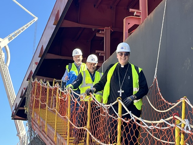 Bishop highlights Church’s ministry to seafarers facing danger and isolation – #Catholic – “The Church has always accompanied people of the sea,” Bishop Frank Schuster, auxiliary bishop for the Archdiocese of Seattle, told EWTN News ahead of his Washington, D.C., visit for the National Day of Prayer and Remembrance for Mariners and People of the Sea on May 22.“We had a couple of seafarers of our own among the apostles — Peter, Andrew, James, and John were fishermen,” said Schuster, who serves as the bishop promoter of Stella Maris in the U.S.Stella Maris, first known as the Apostleship of the Sea, is the Church’s official ministry for seafarers and mariners. Formal Catholic port ministry began in Glasgow, Scotland, in 1920 but was not officially recognized by the Vatican until 1922, when Pope Pius XI granted his approval. The ministry was renamed “Stella Maris” on its 100th anniversary in 2020, a nod to St. John Paul II’s 1997 motu proprio Stella Maris.While the main role of port chaplains with Stella Maris is to celebrate Mass and the sacraments aboard ships, their work includes providing counsel and aid to sailors. “One of the reasons why this ministry is so vitally important is — if you do a quick search of the United Nations, you’ll find this number — it’s fascinating that 80% of all tradable goods have, in some fashion, had to at some point travel by ship,” Schuster said.
Seattle Auxiliary Bishop Frank Schuster gathers with Filipino crew members who were gifted new jackets by Stella Maris after celebrating an early Christmas Mass on board their ship in December 2025. | Credit: Photo courtesy of Bishop Frank Schuster
“They’re performing a service,” he said, “so when they arrive to our ports, we come on board delivering gifts and different items that they might find helpful such as toothbrushes, bars of soap, shaving cream, and razors.”‘A ministry of accompaniment’“It’s a ministry of accompaniment,” Schuster said, explaining that the ministry of port chaplains often includes walking with seafarers struggling with mental health or trauma from their time on board a ship.“Some of these seafarers often have trauma in their past,” Schuster said. “I’ve talked to several seafarers who have been on the Hormuz route — if you’re a sailor on one of these ships and you’re watching missiles fly over you, you are constantly worried about being attacked.”“And so, we can also just be a good ear and listen,” he said. “But also, if we see signs of real depression, we can be helpful there in terms of referrals to make sure that these seafarers get the help that they need.”Stella Maris also often assists crews on abandoned ships, according to Schuster.“There may be a ship out there where the company abandoned the seafarers, so they’re no longer getting paid and they’re just kind of sitting out there on a boat because the country won’t let them leave the boat abandoned,” he explained, citing the crew of the Dali cargo ship that crashed into Baltimore’s Key Bridge in March 2024.A port chaplain with Stella Maris in Baltimore regularly checks in on several members of the Dali crew who have remained in the city amid the ongoing investigation of the incident, the bishop noted.Schuster said his favorite part about his role as bishop promoter of Stella Maris is “just getting on board the ships and being able to do ministry.”“Before I was a bishop, I was a pastor of a parish, and that meant daily accompaniment of people from a variety of different backgrounds and a variety of different needs, and I missed that one-on-one ministry,” he said. “So when I get on board a ship and minister to a crew, being able to celebrate Mass, sit down to eat with them and talk about life, it feels like Iʼm a pastor again. And it feels good.” Bishop highlights Church’s ministry to seafarers facing danger and isolation – #Catholic – “The Church has always accompanied people of the sea,” Bishop Frank Schuster, auxiliary bishop for the Archdiocese of Seattle, told EWTN News ahead of his Washington, D.C., visit for the National Day of Prayer and Remembrance for Mariners and People of the Sea on May 22.“We had a couple of seafarers of our own among the apostles — Peter, Andrew, James, and John were fishermen,” said Schuster, who serves as the bishop promoter of Stella Maris in the U.S.Stella Maris, first known as the Apostleship of the Sea, is the Church’s official ministry for seafarers and mariners. Formal Catholic port ministry began in Glasgow, Scotland, in 1920 but was not officially recognized by the Vatican until 1922, when Pope Pius XI granted his approval. The ministry was renamed “Stella Maris” on its 100th anniversary in 2020, a nod to St. John Paul II’s 1997 motu proprio Stella Maris.While the main role of port chaplains with Stella Maris is to celebrate Mass and the sacraments aboard ships, their work includes providing counsel and aid to sailors. “One of the reasons why this ministry is so vitally important is — if you do a quick search of the United Nations, you’ll find this number — it’s fascinating that 80% of all tradable goods have, in some fashion, had to at some point travel by ship,” Schuster said.
Seattle Auxiliary Bishop Frank Schuster gathers with Filipino crew members who were gifted new jackets by Stella Maris after celebrating an early Christmas Mass on board their ship in December 2025. | Credit: Photo courtesy of Bishop Frank Schuster
“They’re performing a service,” he said, “so when they arrive to our ports, we come on board delivering gifts and different items that they might find helpful such as toothbrushes, bars of soap, shaving cream, and razors.”‘A ministry of accompaniment’“It’s a ministry of accompaniment,” Schuster said, explaining that the ministry of port chaplains often includes walking with seafarers struggling with mental health or trauma from their time on board a ship.“Some of these seafarers often have trauma in their past,” Schuster said. “I’ve talked to several seafarers who have been on the Hormuz route — if you’re a sailor on one of these ships and you’re watching missiles fly over you, you are constantly worried about being attacked.”“And so, we can also just be a good ear and listen,” he said. “But also, if we see signs of real depression, we can be helpful there in terms of referrals to make sure that these seafarers get the help that they need.”Stella Maris also often assists crews on abandoned ships, according to Schuster.“There may be a ship out there where the company abandoned the seafarers, so they’re no longer getting paid and they’re just kind of sitting out there on a boat because the country won’t let them leave the boat abandoned,” he explained, citing the crew of the Dali cargo ship that crashed into Baltimore’s Key Bridge in March 2024.A port chaplain with Stella Maris in Baltimore regularly checks in on several members of the Dali crew who have remained in the city amid the ongoing investigation of the incident, the bishop noted.Schuster said his favorite part about his role as bishop promoter of Stella Maris is “just getting on board the ships and being able to do ministry.”“Before I was a bishop, I was a pastor of a parish, and that meant daily accompaniment of people from a variety of different backgrounds and a variety of different needs, and I missed that one-on-one ministry,” he said. “So when I get on board a ship and minister to a crew, being able to celebrate Mass, sit down to eat with them and talk about life, it feels like Iʼm a pastor again. And it feels good.”