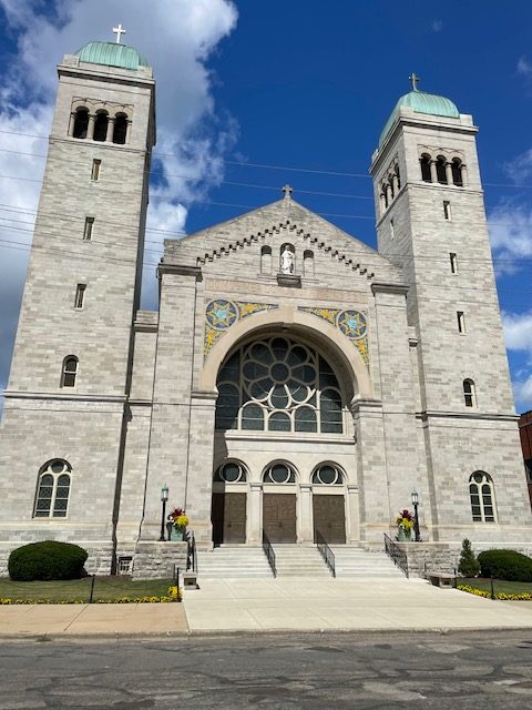 Centennial honors historic Michigan church built amid KKK threats and strikes #Catholic A richly diverse Catholic community in southern Michigan is preparing to mark a milestone: the centennial of St. Mary Star of the Sea in Jackson, where the beauty of sacred space, reverent liturgy, and a vibrant musical tradition continue to shape the lives of the faithful. The church has thrived through historic events and turbulent times, even as it was being rebuilt. In 1924, one of the largest Ku Klux Klan (KKK) rallies ever recorded saw 100,000 participants tramp through Jacksonʼs streets, and parish tradition holds that the Knights of Columbus kept vigil at the construction site to protect it from KKK vandalism.
St. Mary Star of the Sea Parish in Jackson, Michigan. | Credit: Photo courtesy of Father Timothy Nelson
As he prepares to wrap up his 15-year tenure as pastor of the parish, Father Timothy Nelson reflected on the churchʼs enduring vitality: “Our church is not a relic but a dynamic part of the present, enriched by a legacy of faith.”Located west of Detroit, Jackson has long been a railroad hub with ties to the automobile industry. St. Mary’s is one of three current parishes, following a consolidation of several others. Following decades of a strong Polish-American presence, demographic changes have included the growing influx of Hispanic families. Children of the latter now make up about a quarter of the enrollment at St. Mary School.St. Mary’s three spires dominate the skyline, reaching up 180 feet in an imposing Romanesque style. Long regarded as one of the most beautiful churches in Michigan, it features magnificent stained-glass windows fashioned in Innsbruck, Austria, an apse mosaic of Our Lady Star of the Sea, murals of the apostles, and Carrara marble altars and Communion rail. The latter embellishments were donated by George Washington Hill, president of the American Tobacco Co., as a memorial to his young wife, Aquinas Heiler Hill, who died in 1925. The green and red colors in the mosaics around the high altar repeat the original colors used on packs of Lucky Strike cigarettes.
A mosaic of the Crucifixion at St. Mary Star of the Sea Parish in Jackson, Michigan. | Credit: Photo courtesy of Father Timothy Nelson
The present structure replaced an earlier church, with its cornerstone laid on Sept. 23, 1923. Construction faced delays because of a prolonged labor strike at limestone quarries. The era was also marred with social unrest, including the Ku Klux Klan and its virulent anti-Catholicism and racism. Construction was not completed until May 31, 1926, at a cost of 5,000. Then-Auxiliary Bishop Joseph C. Plagens came from Detroit to officiate the dedicatory Mass.Among its treasures is a unique stained-glass rose window memorializing the fallen of the first world war, including nuns who tended the wounded. “The window shows not only the American soldiers and sailors of the war, but even their enemies who reach out to Jesus rising above them,” Nelson said as he gave a tour of the magnificent church. Restoration of the windows cost million and was made possible through the generosity of parishioners and benefactors, including the Eisele Family Foundation. St. Mary’s is depicted in “Buildings of Michigan” by Kathryn Bishop Eckert as one of the most notable in the Mitten State.
Stained-glass window at St. Mary Star of the Sea Parish in Jackson, Michigan. | Credit: Kathryn Mietelka
Now 74, Nelson will step down as pastor this summer. A former cardiologist, he will continue his ministry as chaplain of the St. Pio Medical Center in nearby Howell, which is part of a Vatican-authorized healthcare network inspired by St. Pio of Pietrelcina (Padre Pio). He will be succeeded by Father John Vinton, who will continue offering Traditional Latin Masses and Spanish-language Masses.St. Mary’s serves about 1,086 families, including the active Sacred Heart of Jesus Hispanic Community.Nelson said: “The school is necessary for parish life” and is the most diverse parochial school in the area.The parish’s liturgical life shows both continuity and renewal. The Traditional Latin Mass, celebrated every Sunday, is accompanied by Gregorian chant and organ led by Aine Schroeder, a student at nearby Hillsdale College. Schroeder said the Gregorian schola will chant the “Ave Maria” and “Salve Regina” at the centennial concert. Dispelling concerns that the Latin liturgy is stuck in the past, Nelson said: “I agree with Pope Benedict XVI that the past continues to be lived in the present. We are bringing it into the future.”
Inside St. Mary Star of the Sea Parish in Jackson, Michigan. | Credit: Photo courtesy of Father Timothy Nelson
For longtime parishioner Mary Belknap, a fourth-generation member who serves on the parish guild, St. Mary’s is a spiritual home and a place of encounter. “It’s one of the hallmark parishes in the state. People come from all over to see us and our beautiful church,” she said. Bridging the gaps between communities came easily to educator Belknap, who said that, having been raised in poverty as a child, she has experienced life on the margins, and “I personally reach out to embrace the goodness of other people.”The parishʼs centennial observance will commence with a concert on May 29 and culminate in a solemn Mass on May 31 — exactly 100 years after its first Mass — to be celebrated by Bishop Earl Boyea. Mary Malewitz, parish music director since 1981, is organizing the opening concert, which will feature adult and school choirs, a Hispanic choir, and a Gregorian schola. Between each performance, parishioners will sing their favorite hymns. “St. Mary’s has brought glory to Michigan for generations,” she told EWTN News. Centennial honors historic Michigan church built amid KKK threats and strikes #Catholic A richly diverse Catholic community in southern Michigan is preparing to mark a milestone: the centennial of St. Mary Star of the Sea in Jackson, where the beauty of sacred space, reverent liturgy, and a vibrant musical tradition continue to shape the lives of the faithful. The church has thrived through historic events and turbulent times, even as it was being rebuilt. In 1924, one of the largest Ku Klux Klan (KKK) rallies ever recorded saw 100,000 participants tramp through Jacksonʼs streets, and parish tradition holds that the Knights of Columbus kept vigil at the construction site to protect it from KKK vandalism.
St. Mary Star of the Sea Parish in Jackson, Michigan. | Credit: Photo courtesy of Father Timothy Nelson
As he prepares to wrap up his 15-year tenure as pastor of the parish, Father Timothy Nelson reflected on the churchʼs enduring vitality: “Our church is not a relic but a dynamic part of the present, enriched by a legacy of faith.”Located west of Detroit, Jackson has long been a railroad hub with ties to the automobile industry. St. Mary’s is one of three current parishes, following a consolidation of several others. Following decades of a strong Polish-American presence, demographic changes have included the growing influx of Hispanic families. Children of the latter now make up about a quarter of the enrollment at St. Mary School.St. Mary’s three spires dominate the skyline, reaching up 180 feet in an imposing Romanesque style. Long regarded as one of the most beautiful churches in Michigan, it features magnificent stained-glass windows fashioned in Innsbruck, Austria, an apse mosaic of Our Lady Star of the Sea, murals of the apostles, and Carrara marble altars and Communion rail. The latter embellishments were donated by George Washington Hill, president of the American Tobacco Co., as a memorial to his young wife, Aquinas Heiler Hill, who died in 1925. The green and red colors in the mosaics around the high altar repeat the original colors used on packs of Lucky Strike cigarettes.
A mosaic of the Crucifixion at St. Mary Star of the Sea Parish in Jackson, Michigan. | Credit: Photo courtesy of Father Timothy Nelson
The present structure replaced an earlier church, with its cornerstone laid on Sept. 23, 1923. Construction faced delays because of a prolonged labor strike at limestone quarries. The era was also marred with social unrest, including the Ku Klux Klan and its virulent anti-Catholicism and racism. Construction was not completed until May 31, 1926, at a cost of 5,000. Then-Auxiliary Bishop Joseph C. Plagens came from Detroit to officiate the dedicatory Mass.Among its treasures is a unique stained-glass rose window memorializing the fallen of the first world war, including nuns who tended the wounded. “The window shows not only the American soldiers and sailors of the war, but even their enemies who reach out to Jesus rising above them,” Nelson said as he gave a tour of the magnificent church. Restoration of the windows cost million and was made possible through the generosity of parishioners and benefactors, including the Eisele Family Foundation. St. Mary’s is depicted in “Buildings of Michigan” by Kathryn Bishop Eckert as one of the most notable in the Mitten State.
Stained-glass window at St. Mary Star of the Sea Parish in Jackson, Michigan. | Credit: Kathryn Mietelka
Now 74, Nelson will step down as pastor this summer. A former cardiologist, he will continue his ministry as chaplain of the St. Pio Medical Center in nearby Howell, which is part of a Vatican-authorized healthcare network inspired by St. Pio of Pietrelcina (Padre Pio). He will be succeeded by Father John Vinton, who will continue offering Traditional Latin Masses and Spanish-language Masses.St. Mary’s serves about 1,086 families, including the active Sacred Heart of Jesus Hispanic Community.Nelson said: “The school is necessary for parish life” and is the most diverse parochial school in the area.The parish’s liturgical life shows both continuity and renewal. The Traditional Latin Mass, celebrated every Sunday, is accompanied by Gregorian chant and organ led by Aine Schroeder, a student at nearby Hillsdale College. Schroeder said the Gregorian schola will chant the “Ave Maria” and “Salve Regina” at the centennial concert. Dispelling concerns that the Latin liturgy is stuck in the past, Nelson said: “I agree with Pope Benedict XVI that the past continues to be lived in the present. We are bringing it into the future.”
Inside St. Mary Star of the Sea Parish in Jackson, Michigan. | Credit: Photo courtesy of Father Timothy Nelson
For longtime parishioner Mary Belknap, a fourth-generation member who serves on the parish guild, St. Mary’s is a spiritual home and a place of encounter. “It’s one of the hallmark parishes in the state. People come from all over to see us and our beautiful church,” she said. Bridging the gaps between communities came easily to educator Belknap, who said that, having been raised in poverty as a child, she has experienced life on the margins, and “I personally reach out to embrace the goodness of other people.”The parishʼs centennial observance will commence with a concert on May 29 and culminate in a solemn Mass on May 31 — exactly 100 years after its first Mass — to be celebrated by Bishop Earl Boyea. Mary Malewitz, parish music director since 1981, is organizing the opening concert, which will feature adult and school choirs, a Hispanic choir, and a Gregorian schola. Between each performance, parishioners will sing their favorite hymns. “St. Mary’s has brought glory to Michigan for generations,” she told EWTN News.