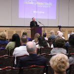 Healing the Hidden Wounds: A statewide Catholic response takes shape #Catholic - The doors of the Church, Pope Francis has said, must always remain open – especially for those carrying unseen wounds.
On May 2, that call took concrete shape as more than 200 clergy, religious, educators, mental health professionals, ministry leaders and more gathered with a shared purpose: confronting the growing mental health crisis not from the margins, but from the heart of the faith community.
“Struggle is not a failure of humanity. Silence is. When we treat addiction or mental illness as something that must be concealed or explained away or endured alone, we unintentionally transform human suffering into spiritual isolation – and isolation is where despair grows,” said Bishop John Dolan of the Diocese of Phoenix, the keynote speaker for the New Jersey Catholic Mental Health Conference held at the St. John Neumann Pastoral Center, Piscataway.
“One of the hardest truths to face is that a person can be deeply loved but still feel completely alone,” he said. “That’s why presence matters. Not abstract care, but real encounter.”
Hosted by the Diocese of Metuchen, the conference, titled “From Isolation to Belonging: Mental Health and the Catholic Church,” brought together participants from all five New Jersey (arch)dioceses, as well as leaders from multiple religions. The daylong gathering blended pastoral reflection with practical strategy from Bishop Dolan and leading Catholic voices and experts in the field.
The day started with Mass celebrated by Cardinal Joseph Tobin of the Archdiocese of Newark. Concelebrating were: Bishop Joseph Williams of the Diocese of Camden; Father Jonathan S. Toborowsky, administrator of the Diocese of Metuchen; Bishop Dolan, and Father Tim Graff from the Archdiocese of Newark.&nbsp;
Coordinated by the New Jersey Catholic Conference in partnership with the state’s dioceses, Catholic Charities agencies and the Catholic Healthcare Partnership of New Jersey, the conference reflected a growing recognition among Church leaders: the mental health crisis is not only a clinical concern, but a pastoral one.
That message was echoed in Cardinal Tobin’s opening remarks, where he invoked Pope Francis’ vision of the Church as “a field hospital after battle.” The image, he suggested, is more than metaphor. It is a directive – one that calls the Church to move toward those who are wounded, to listen without judgment, and to build communities where isolation gives way to belonging.
Suffering in Silence
In his keynote, Bishop Dolan, a survivor of suicide loss, spoke on the effects of isolation and the importance of accompaniment. He cited a 2023 report from the U.S. Surgeon General that found how chronic loneliness can increase the risk of premature death to a level comparable to smoking up to 15 cigarettes a day. In addition, chronic loneliness can raise the risk of dementia in older adults by roughly 50%.
“One of the hardest truths to face is that a person can be deeply loved but still feel completely alone,” he said. “That’s why presence matters. Not abstract care, but real encounter.”
A person can be in a room and still be distant. One can be surrounded by people and still feel alone. To be with someone is to be present in a way that acknowledges the other and allows that person to matter. Show up. Stay. Listen.
“That is why the word ‘with’ carries such weight,” Bishop Dolan said. “It points to something deeper than proximity. It speaks of relationship. It speaks of identity.”
Being present for others is especially important in a world in which humanity is connected more than ever before, while true communication is lacking.
“I have come to say clearly: Isolation kills but communion heals. I say that because I’ve seen it and I’ve experienced it,” he said, explaining that five of his family members have died by suicide.&nbsp;
“There is a silence that follows this kind of loss. It’s different,” he explained. “There are questions that don’t always have answers. You find yourself wondering, ‘What more could have been done? Where did I go wrong? Why wasn’t I there? How may I have made a difference?’”
This is also true among leaders of faith, Bishop Dolan said. “I’ve met priests who waited years before seeking help, years of quiet anguish, because they feared disappointing their bishop, their community or their people. I’ve met women religious who believe their vows required endurance without expression. Endurance is not the same as holiness. Suffering in silence is not a sacrament or religious virtue.”
Hope and Healing
Accompaniment was among the first topics that Beth Hlabse, program director of the&nbsp;Fiat Program on Faith and Mental Health&nbsp;at Notre Dame University’s McGrath Institute for Church Life, discussed in her presentation.
Overcoming mental illness “is not just a matter of willpower,” she stressed, urging anyone accompanying a loved one to look at is as a “journey of working with [that person], rather than compounding the shame by saying it’s only a matter of willpower – because it’s not.”
“Remember, your role is not to diagnose,” she said. “[It is] to encounter each person according to their uniqueness, to discern their level of suffering and to ask the Lord, ‘Lord, how am I called to walk with this person? How am I called to support them in accessing a broader network of resources beyond what I and our immediate community can offer?’”
With more than one in five American adults living with a mental illness (23.4%), and more than one in 20 U.S. adults living with a serious mental illness (5.6%), she also addressed contributing factors, including illness, and biological, environmental and developmental elements.
Environmental factors aren’t just natural surroundings, she said. “It’s also social media and peer influence – things that put stress on us and increase our vulnerability to mental illness.”
When it comes to developmental factors, consider: “What was the family environment like growing up? The school and neighborhood environments … because when we’re young, we’re more susceptible to environmental influence than we are when we’re older. … Mental illness is not the result of just any one factor.”
God, she continued, is with every person in times of anxiety, depression, stress and illness, as seen when Jesus prayed in the Garden of Gethsemane. “God enters into the very depths of our suffering, so that even in times of desolation, we believe that God is there.”
“Healing is a movement from isolation toward communion, toward an experience of hope amidst hardship,” she said.
National Initiatives
Ben Wortham, vice president for Behavioral Health Integration at&nbsp;Catholic Charities USA, and Deacon Ed Shoener, founder of the International Association of Catholic Mental Health Ministers, presented a collaborative vision for addressing mental health during their session, “Mental Health Ministries for Our Parishes: National Initiatives and Local Action.” Their presentation emphasized that effective mental health care must extend beyond clinical treatment to include housing, community support, education, and spiritual care.
Wortham stressed that “mental health doesn’t happen in a vacuum,” underscoring the need for collaboration among mental health providers, health care systems, and the social determinants of health — including housing, income, employment, education, family and social support, community safety, and access to food and transportation.
He noted that even when people seek professional mental health care, recovery remains difficult if they return to unstable living conditions or lack essential support systems.
“Especially with the poor and vulnerable populations, we can’t talk about mental health without talking about basic needs being met,” he said, highlighting three initiatives developed through Catholic Charities USA:

Healthy Housing Initiative — a program currently operating in five major cities that integrates mental health support with housing services, helping reduce chronic homelessness by pairing affordable housing with onsite mental health care.
“Sister Hope” AI Mental Health Chatbox — a 24/7 faith-aligned support platform that provides coaching programs, referrals to Catholic Charities services, and expanded access for hard-to-reach populations.
“Whole Hearted” — trauma-informed workshops and parish resources designed to integrate spirituality and religious practices with behavioral health education and mental health awareness.

Wortham encouraged attendees to stop viewing mental health as an isolated issue and instead focus on integrated care that addresses both emotional and material needs. He pointed to the importance of Medicaid expansion — noting that 10 states have yet to adopt the program — as well as increasing Medicaid reimbursement rates to help provide competitive salaries for mental health professionals. Above all, he emphasized the importance of continued collaboration among churches, health systems, and community organizations.
Local Action on the Parish Level
For Deacon Shoener, the central mission of parish mental health ministry is simple but profound: “to be a healing presence in our parishes.” His hope, he said, is that one day “the first place someone with mental health challenges would look for understanding and support is the Catholic Church.”
That vision is deeply personal for Shoener. Nearly 10 years ago, he lost his daughter, who struggled with bipolar disorder and died by suicide. Reflecting on the experience, he explained that “a mental health crisis is also a spiritual crisis,” one that must be met with the love of Christ and the promise of hope.
Deacon Shoener shared that the obituary he wrote for his daughter became an unexpected ministry of its own. More than a tribute to her life, it openly addressed the realities of mental illness and the needs of those who suffer in silence. The obituary spread widely online, reaching millions of readers and prompting tens of thousands of people around the world to contact him with their own stories. Again and again, he heard the same concern: many felt the Church offered little support to individuals experiencing mental illness or to their loved ones.
That response ultimately led Deacon Shoener to partner with Bishop Dolan in founding the International Association of Catholic Mental Health Ministers. Today, the lay association includes more than 7,000 members in over 75 countries and works to reduce stigma surrounding mental illness while equipping parish leaders with resources and support.

Click here for more photos of “Mental Health and the Catholic Church.”

“Mental illness is an illness just like all the other illnesses that doctors treat, and it needs to be understood that way,” Deacon Shoener said.
He noted that current efforts focus on integrating mental health ministry into the everyday life of the Church and normalizing conversations around mental wellness in the same way physical health concerns are addressed.
Addressing conference attendees directly, he challenged those interested in mental health ministry to consider their own willingness to be vulnerable. “Those of you who want to get involved in mental health ministry … are you ready to share your story?” he asked, stressing that trust and accompaniment often begin with personal witness.
He also pointed to three major barriers that prevent many people from seeking support within the Church: fear that clergy or parish leaders will not understand their experience, fear of judgment and stigma, and the perception that little support exists within parish communities.
Still, he encouraged participants to see their presence at the conference as a call to action. “If you are here, you are being tapped on the shoulder in some way to bring this mental health ministry to your community,” he said.
To learn more about Catholic mental health ministry resources, visit the International Association of Catholic Mental Health Ministers at https://catholicmhm.org.
Jennifer Mauro is the managing editor of the Catholic Star Herald, the newspaper for the Diocese of Camden. Mary Morrell is the editor-in-chief of The Catholic Spirit, the newspaper for the Diocese of Metuchen.

Click here to subscribe to our weekly newsletter.

&nbsp;