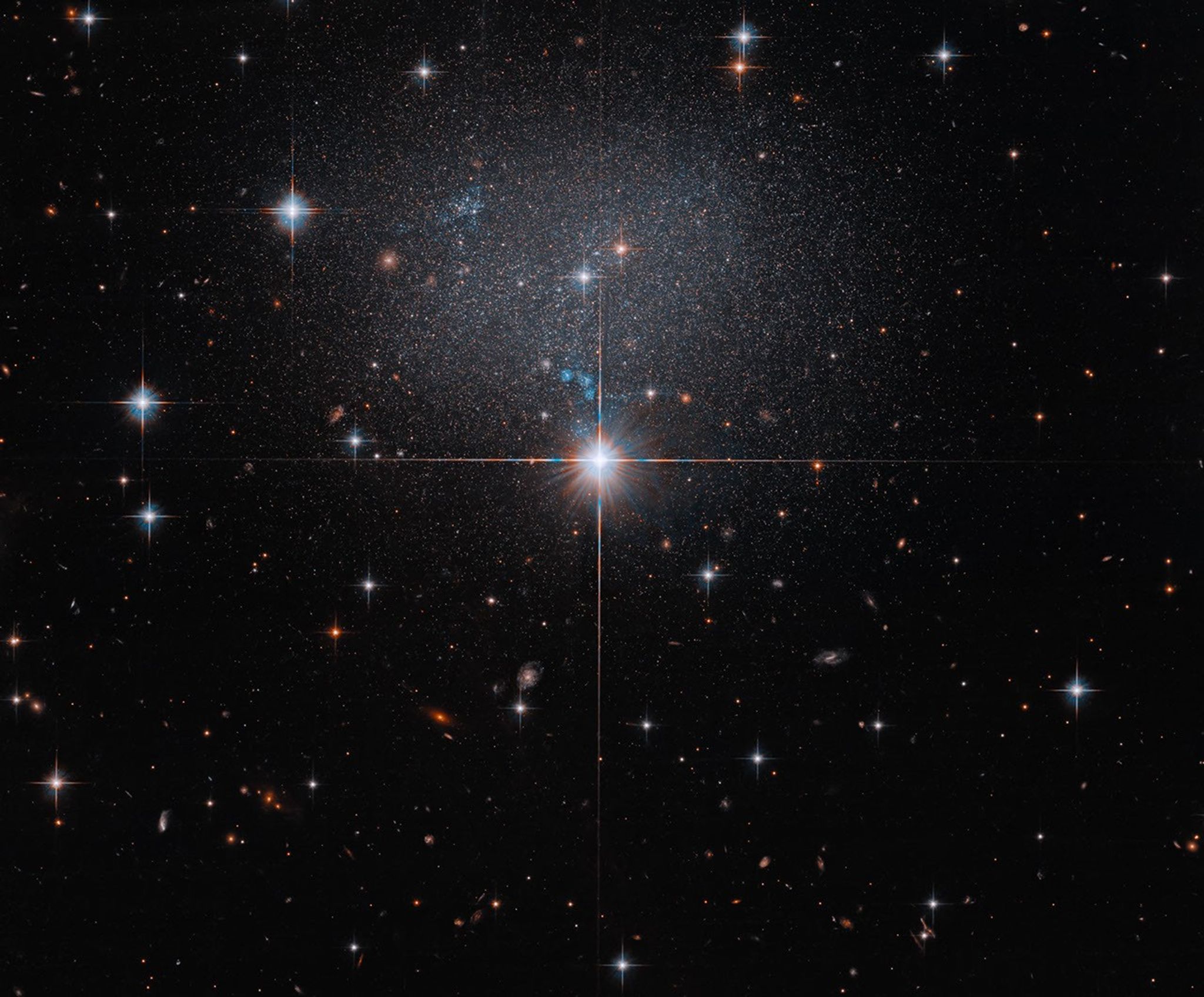 Hubble Spies Faint Irregular Galaxy – This NASA Hubble Space Telescope image captures the faint glow of the dwarf irregular galaxy ESO 490-017. Hubble Spies Faint Irregular Galaxy – This NASA Hubble Space Telescope image captures the faint glow of the dwarf irregular galaxy ESO 490-017.