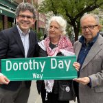 New sign on a street corner in Brooklyn, N.Y., honors legacy of Dorothy Day #Catholic – BROOKLYN, N.Y. (OSV News) — Dorothy Day’s extraordinary life began in Brooklyn, and now a street corner near her birthplace has been named after the legendary co-founder of the Catholic Worker Movement.
The intersection of Pineapple and Henry streets in the Brooklyn Heights neighborhood is now officially called “Dorothy Day Way” in honor of the “Servant of God,” who was born nearby at 71 Pineapple St. in 1897.
On May 2, Martha Hennessy, Day’s granddaughter, and members of the Dorothy Day Guild, the organization promoting her cause for sainthood, joined clergy for the ceremony to unveil the street sign.
Hennessy and Councilman Lincoln Restler, who sponsored legislation in the City Council to name the street corner, did the honors of pulling the string to remove a covering and reveal the street sign.
Hennessy, who like her grandmother is a Catholic peace activist, called the ceremony “a beautiful moment.”
The street naming marked the second time New York City has paid tribute to Day.

Click here to subscribe to our weekly newsletter.

In 2021, the city commissioned a Staten Island ferry in her name, and the Dorothy Day had its inaugural voyage in 2023.
Day (1897-1980) was a journalist and social activist who lived a wild, bohemian youth before becoming a Catholic in 1927. She fed and clothed the poor, advocated for civil rights and protested all wars.
On May 1, 1933, she co-founded the Catholic Worker Movement with Peter Maurin. It is a faith-based organization that urges members to perform the corporal works of mercy and work for peace and justice. At the same time, Day also began publishing a newspaper, The Catholic Worker, which is still published today.
Day’s life of faith inspired others, said Father Anthony Andreassi, administrative vicar for the Brooklyn Oratory Parishes in Brooklyn Heights.
“She was a convert to Catholicism, a woman of incredible faith and committed to the poor,” he told The Tablet, newspaper of the Brooklyn Diocese. “I know many people who have been attracted to the church because of Dorothy Day and have come to accept baptism.”
New York Cardinal John J. O’Connor officially opened Day’s sainthood cause in 2000, granting her the title of “Servant of God.”
Twenty-one years later, following the conclusion of the diocesan phase of the investigation into her life and her fitness for sainthood, her case was submitted to the Vatican for review by New York Cardinal Timothy M. Dolan.
Kevin Ahern, board chairman of the Dorothy Day Guild, said he sees the street corner naming as an opportunity to promote her good works.
“And maybe by learning about her,” Ahern said, “they can be inspired by her to live their life a little … and make the world a better place.”
Alex Avitabile, a guild board member, spearheaded the drive to have the street corner named for Day, whom he met in 1970. He asked Restler to sponsor legislation.
Avitabile recalled walking up to her after a talk she had given at the Catholic Worker House in Rochester and telling her how much he admired her. Even back then, he said he felt he was in the presence of a saintly person.
“I knew,” Avitabile recalled. “She had a way about her — her eyes. There are a few people I’ve met who are saintly people. And I could just see that.”
The Catholic Worker Movement, which celebrated its 93rd anniversary on May 1, is still going strong today, according to guild members.
Hennessy said she is pleased to see that people are still inspired by her grandmother, even 46 years after her death.
“It’s pretty astounding, the place she holds in their hearts and in their minds,” she told The Tablet. “It’s only expanding, and I truly believe that she will bring so much good to the Catholic Church and bring people back to the church.”
Paula Katinas is senior reporter at The Tablet, newspaper of the Diocese of Brooklyn. This story was first published in The Tablet and distributed in partnership with OSV News.