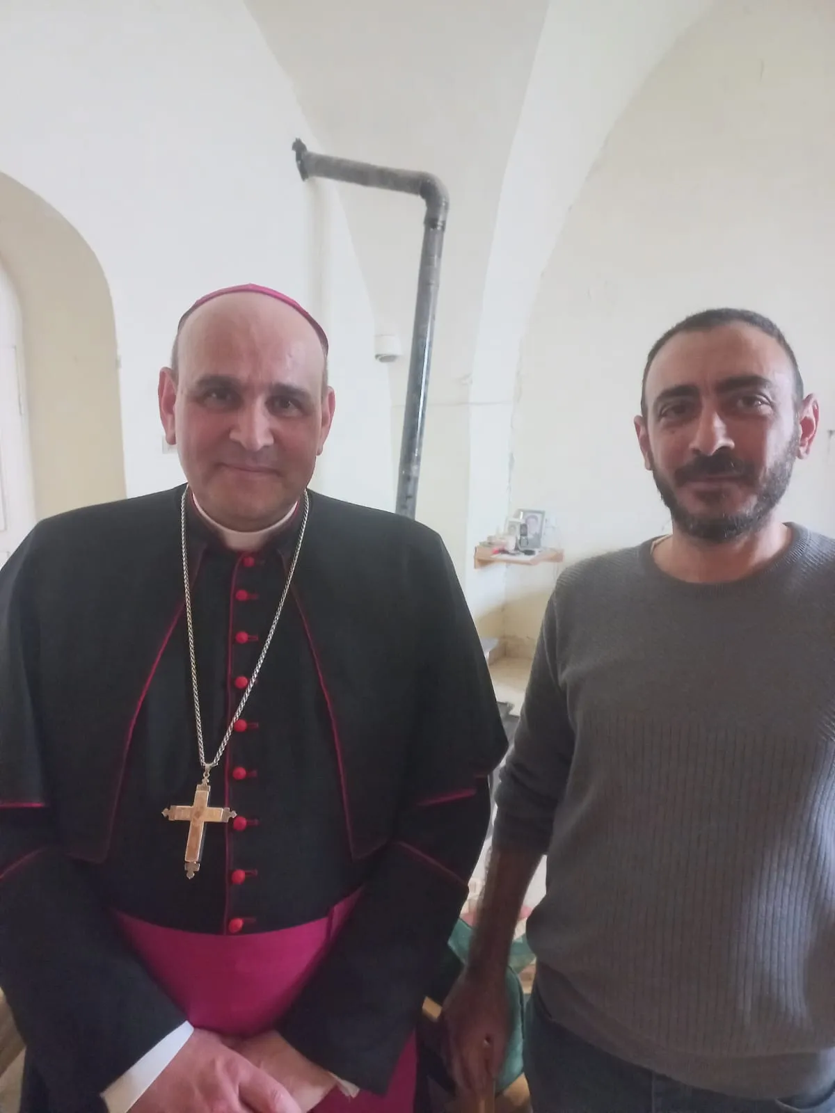 Outrage grows over alleged bulldozing of Catholic monastery and school in Lebanon #Catholic In southern Lebanon, the village of Yaroun has drawn widespread attention after images and video circulated showing the demolition, allegedly by Israeli forces, of a monastery and Catholic school belonging to the Salvatorian Sisters.Yarounʼs mayor, Adib Ajaka, rejected claims by the Israeli army that it did not know the buildings were religious places, and the Council of Melkite Greek Catholic Bishops in Lebanon urged the Lebanese government and the United Nations “to protect the property of civilians and religious institutions, citing in particular the village of Yaroun,” according to the Associated Press.Speaking to ACI MENA, the Arabic-language sister service of EWTN News, Ajaka clarified that some media outlets have been recirculating images of a destroyed church as if they were from the latest incident, but the church itself had already been targeted multiple times since 2024. He stressed that the most recent incident concerns the demolition of the monastery and the school.Responding to the Israeli army’s claim that “there were no indications that it was a religious building,” Ajaqa rejected the statement as unconvincing, noting that the site was clearly identifiable, bearing a cross and a statue of the Virgin Mary. He also pointed out that the church had been targeted previously and that footage from 2024 showed the deliberate destruction of a statue of St. George.
 
 Adib Ajaka, mayor of the village of Yaroun, is pictured with the apostolic nuncio to Lebanon, Archbishop Paolo Borgia. | Credit: Photo courtesy of Adib Ajaka
 
 Ajaka said images published by Israel showing the diocese and a nearby clinic were used to suggest that the monastery had not been destroyed, but in reality they referred to a separate building housing a clinic run by the Order of Malta. He suggested that the presence of the organization’s flag may have contributed to it being spared so far. According to Ajaka, the bulldozing operations took place after the ceasefire came into effect. At first, residents did not grasp the scale of what was happening, as they remained in contact with nearby towns such as Rmeish and Ain Ebel, where no strikes or shelling had been reported from Yaroun. This created the impression that the village had not been directly targeted. It later became clear, however, that what had taken place was not bombardment but the widespread bulldozing of homes.Yaroun is home to about 60 Melkite Catholic families — all of whom fled at the outbreak of the war in 2024. Seventeen families returned during the initial ceasefire period, but many others were unable to do so due to the destruction of their homes. Today, residents remain unable to return, scattered between rented accommodations, monasteries, and relatives’ homes, while some have relocated to nearby Christian villages in the south.Ajaka noted that assistance to residents has so far been limited, emphasizing that the most urgent need is direct financial support to help cover rent. At the same time, he expressed gratitude for the support provided by the Vatican and for the continued efforts of the apostolic nuncio through regular visits and follow-up on the situation of displaced families.
 
 The historic stone presented to Pope Leo XIV during his visit to Lebanon in December 2025. | Credit: Rumi Al-Haber/ACI MENA
 
 He also recalled that during the pope’s visit to Lebanon in December 2025, a historic stone from the village church dating back to 1872, engraved with an image of St. George, was presented to him in the hope of drawing attention to Yaroun and its people.Today, the fate of this stone remains unknown, as the church has been destroyed and residents are unable to return to see what remains. Ajaka stressed that the destroyed homes of the Catholic families there are over a century old and are purely civilian properties.Church vandalism across LebanonThe alleged demolitions in Yaroun come amid recent and varied incidents of church vandalism in Lebanon, with multiple places of worship targeted and their contents deliberately damaged. Among them, the Church of Mar Shalita in Qobeiyat was stormed and vandalized. And in Ajaltoun, the Church of Our Lady was targeted, with intruders stealing items, destroying furniture, and leaving bullets scattered on the floor.Taken together, these incidents reflect a broader climate in which Lebanese Christians increasingly feel under pressure, facing different forms of intimidation and attack from multiple actors.This story was first published by ACI MENA, the Arabic-language sister service of EWTN News, and has been adapted by EWTN News English.