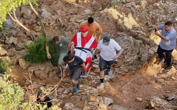 97-year-old cardinal, tortured under communism, climbs Medjugorje’s Apparition Hill #Catholic Cardinal Ernest Simoni, 97, who was tortured by Albaniaʼs communist regime, climbed Apparition Hill in Medjugorje on June 23, the day before the 45th anniversary of the start of the alleged apparitions.Six young people claimed to have seen the Virgin Mary for the first time on June 24, 1981, the feast day of St. John the Baptist, on Mount Podbrdo. Since then, some of those visionaries say they still receive messages from the Mother of God on a daily basis.Following a lengthy investigation, the Dicastery for the Doctrine of the Faith approved a document in 2024 titled The Queen of Peace, which acknowledges the spiritual fruits that have been borne, finds no obstacles in the alleged messages received, and makes no pronouncement regarding the supernatural nature of the phenomena.Assisted by young people from the Cenacolo Community, who carried the cardinal part of the way as he was seated on a litter, the Albanian cardinal traversed a portion of the rocky path on foot, though not without difficulty.
 
 Members of the Cenacolo Community carry Cardinal Simoni in Medjugorje. | Credit: Courtesy of Maria Vision Medjugorje
 
 Along the way, he blessed those present who stopped to greet him. Upon reaching the summit of the mountain, he prayed the rosary beside the statue of the Virgin Mary and blessed the water with which he sprinkled the crowd before returning.The footage of this pilgrimage, provided by María Visión Medjugorje, bears witness to the determination of the cardinal who, as a priest, endured the communist dictatorship of Enver Hoxha, the man who proclaimed Albania to be “the first atheist state in the world."A priest twice sentenced to deathBorn in 1928 in the village of Troshani, the young Simoni underwent formation with the Franciscans from 1938 to 1948, until a bloody religious persecution eliminated the communityʼs superiors and forced him to continue his formation in secret.In 1956, he was ordained a priest at St. Stephenʼs Cathedral in the Archdiocese of Shkodrë-Pult. Seven years later, after celebrating Christmas Eve Mass on Dec. 24, 1963, he was arrested by four agents and informed that he would be executed by hanging, accused of having celebrated a Mass for the repose of the soul of recently assassinated U.S. President John F. Kennedy at the behest of St. Paul VI. According to his own account, an attempt was made to entrap him by placing another prisoner in his cell who began complaining about the Communist Party. News of his preaching about love for oneʼs enemies while in prison reached the dictator, who decided to commute his sentence to 28 years of forced labor. During those years, he continued to celebrate Mass and exercise his priestly ministry clandestinely.In 1973, he was once again sentenced to death, accused of inciting a rebellion. However, exonerating testimony prevented the immediate execution of the sentence, and he remained in prison for another 18 years until his release in 1981.He continued his pastoral work in secret for another nine years, until the fall of the communist regime in 1990. “The Lord has helped me to serve so many people and to reconcile many, driving hatred and the devil away from the hearts of men,” he stated upon concluding his testimony before Pope Francis in October 2016.A month later, Simoni was created a cardinal at the consistory held on Nov. 19, 2016.This story was first published by ACI Prensa, the Spanish-language sister service of EWTN News. It has been translated and adapted by EWTN News English.
