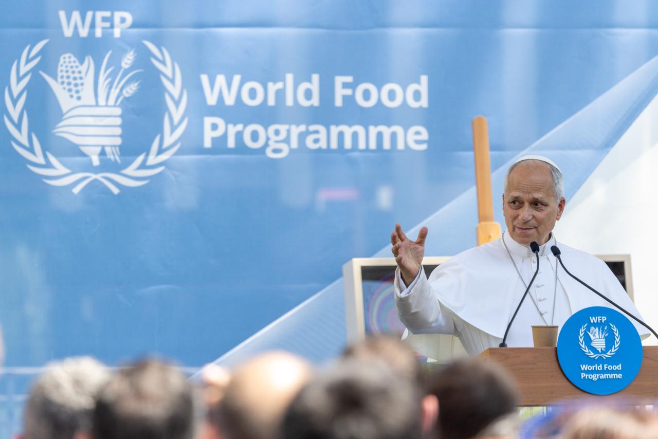 Pope Leo XIV to UN: To combat hunger, focus on humanity #Catholic Pope Leo XIV called on the United Nations (U.N.) to prioritize people in combating world hunger and said feeding the hungry is an essential part of peacemaking.The pontiff visited the headquarters of the U.N. Food and Agriculture Organization in Rome on Monday. In his remarks, Leo emphasized the seriousness of world hunger, explaining that it often fuels other social challenges, particularly migration.“More than merely a humanitarian concern, hunger erodes social cohesion, heightens the risk of conflict, and fuels forced migration,” Leo said. “In effect, conflicts are ‘fed’ more readily than people are nourished. This reality reflects not only operational shortcomings but also a fundamental imbalance in political and moral priorities.”The pope also stressed the importance of multilateral collaboration, stating that each state shares co-responsibility to “recognize the inherent God-given dignity of every person.” He also encouraged secular governments to be open to collaborating with the Catholic Church to assist the most vulnerable, recognizing their fundamental human right to adequate food.“Access to adequate food is a fundamental human right grounded in the dignity of every person,” Leo remarked.“The Catholic Church — through parishes, dioceses, Caritas agencies, and other faith-based initiatives — often reaches vulnerable populations in areas inaccessible to international actors. I therefore encourage the World Food Programme and its partners to continue supporting these efforts.”The U.N. Food and Agriculture Organization was established in 1945 in response to widespread hunger and food insecurity worldwide following World War II. In his address, Leo XIV praised the progress of the organization’s mission while warning the U.N. about the dangers of a bureaucracy that slows the delivery of food assistance to disadvantaged populations.“Implementing this appeal [to fight hunger] effectively requires reducing unnecessary bureaucracy so that transparency and accountability serve people rather than impede assistance,” the pope said.