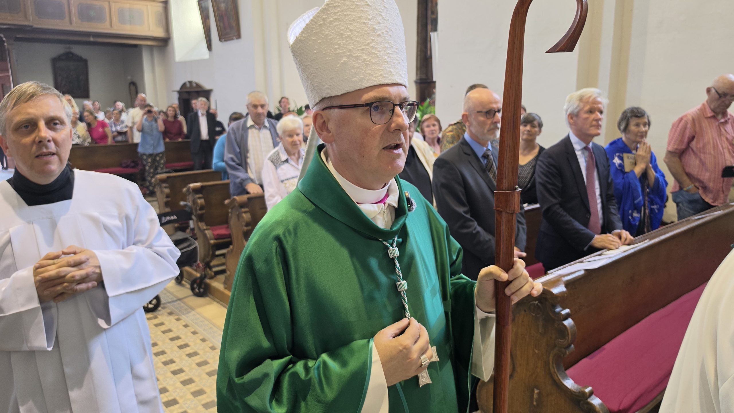 Prague archbishop, German ambassador mark post-WWII massacre – #Catholic – On June 3, the archbishop of Prague and the German ambassador to the Czech Republic commemorated the biggest massacre of the German-speaking population in Czechoslovakia — some say in Europe — after World War II. In the town of Postoloprty in May and June 1945, the Czechoslovak army killed at least 763 people, according to a 1947 Czechoslovak parliamentary commission, though the total number is estimated by some to be 1,000-2,000. They were mostly civilians put into mass graves, and no one was ever convicted.Archbishop Stanislav Přibyl; Rüdiger Heinrich, a military attaché from the German embassy; the faithful; and students from local schools and from Prague marched 10.5 miles from Postoloprty to Žatec. The marchers had the names of the victims written on a scarf, a stone, or a piece of cardboard to make them more visible and present.
 
 Participants walk through the countryside between Postoloprty and Žatec, Czech Republic, during the reconciliation pilgrimage on June 3, 2026. | Credit: Diocese of Litoměřice
 
 The pilgrimage concluded at the Church of the Coronation of the Virgin Mary, where Přibyl celebrated Mass. German Ambassador Peter Reuss joined the ceremony.In his homily, Přibyl admitted they were tired and sweaty. It was not just a walk from one city to another, but one through “the land of memory, through places where the history of our country touches on pain, guilt, helplessness, silence, and the desire for healing.”The topic of reconciliation is not raised to accuse anyone, “but because God invites us to the truth which is the first step towards reconciliation,” the religious leader clarified and continued: “In a time when everyone believes he has his own truth and when our truths sometimes differ diametrically, we are invited to the truth that is known and spoken, but which is accompanied by mercy, because what good would it be for us to be right if we were left alone with it?”The prelate saw the pilgrimage as a reminder that “peace is not created only by words, but sometimes by steps.” It is “a quiet step” that says “I do not want to forget, I do not want to hate,” the archbishop said.The faithful bring to the Lord “the dead, known and unknown, families whose stories have been broken, silence that has often lasted too long,” Přibyl recalled, adding: “We also bring our own fear of the truth and our own unwillingness to forgive.”He characterized the Eucharist and the Mass as “the deepest place of reconciliation.” There, Christ does not proclaim that “the past does not matter or that sin is not sin,” yet he does not reproach us, the prelate explained.“The risen Lord had been crucified before and so comes among us not without wounds,” Přibyl said. “But his wounds are healed, and by his wounds we are healed,” the archbishop concluded.
 
 A wooden cross and memorial plaque stand near the mass graves of ethnic Germans killed in 1945, marked during the reconciliation pilgrimage near Postoloprty, Czech Republic, on June 3, 2026. | Credit: Diocese of Litoměřice
 
 Part of a Year of ReconciliationThe event was part of the Year of Reconciliation in the Diocese of Litoměřice, which borders Germany. Přibyl declared it for 2026 while he was bishop of the diocese; he has since been appointed archbishop of Prague but remains its apostolic administrator.Each month, a gathering takes place in a different location linked to atrocities before and after World War II. In May, for example, Přibyl presided over an ecumenical ceremony in Terezín (Theresienstadt), which served as a Nazi transit camp and propaganda showpiece during the war.When Nazi Germany invaded Czechoslovakia, it established the Protectorate of Bohemia and Moravia. After Germanyʼs defeat in 1945, some ethnic Germans were killed or died by suicide, and approximately 3 million were expelled from Czechoslovakia.