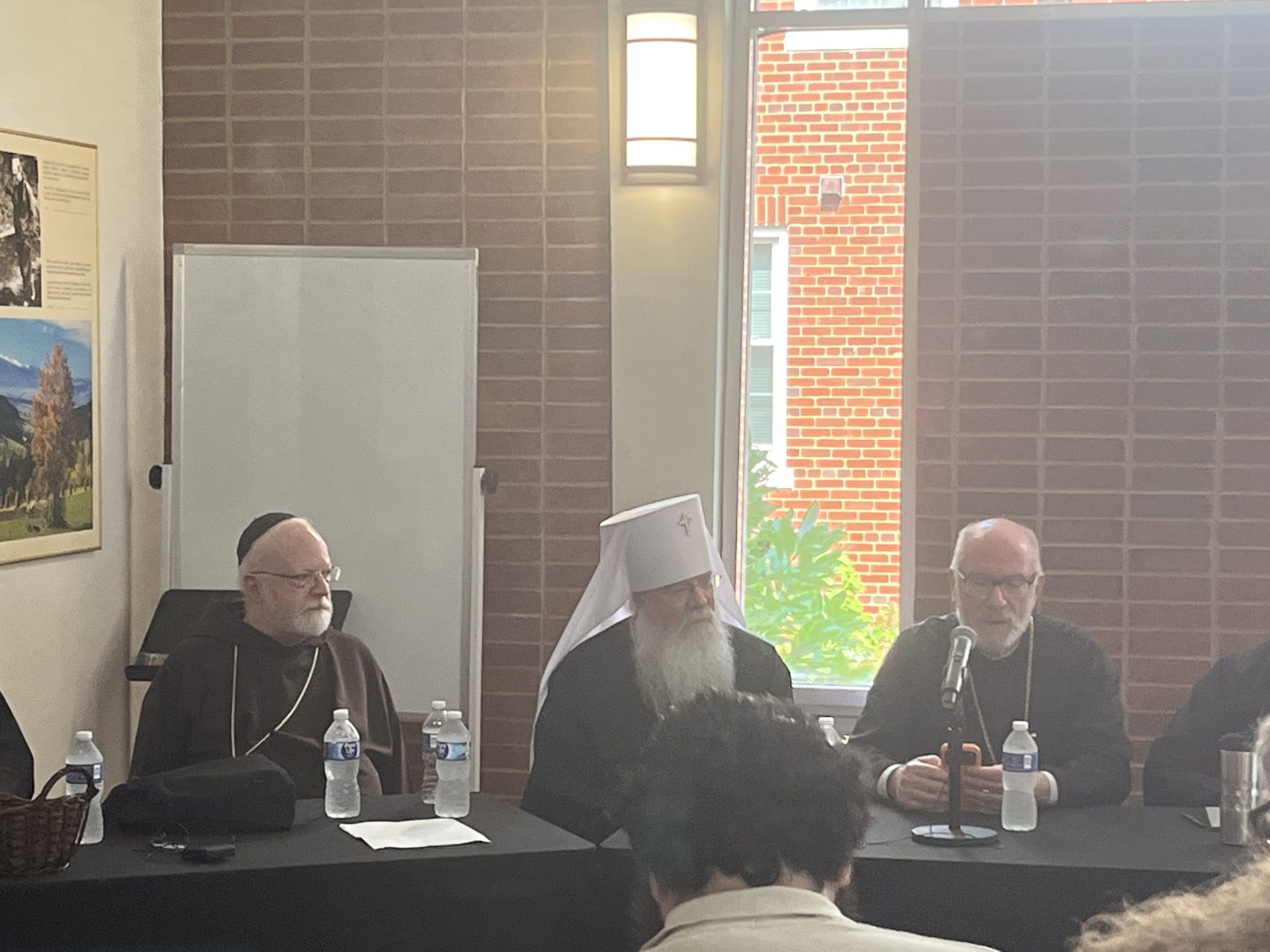 Catholic, Orthodox bishops join in dialogue and prayer at Washington, D.C., conference #Catholic Catholic and Eastern Orthodox bishops exchanged dialogue and joined together in prayer at an ecumenical conference in Washington, D.C., this week with a hope that one day the Eastern and Western churches will be reunited.The conference, held at the retreat house for the St. John Paul II National Shrine on July 13–15, was organized by the Orientale Lumen Foundation. Jack Figel, an Eastern Catholic who founded the group, named it after St. John Paul II’s apostolic letter expressing hope for reunification.Speakers included the secretary for the Vatican Dicastery for Promoting Christian Unity, Archbishop Flavio Pace; the primate of the Orthodox Church in America, Metropolitan Tikhon Mollard; Cardinal Seán Patrick OʼMalley; Greek Orthodox Bishop Anthony Vrame; and Romanian Catholic Bishop John Michael Botean.“I grew up with — I lived with — the tension between East and West my whole life,” Figel told EWTN News.A reunification, Figel said, “all depends on the Holy Spirit.” He said: “It is going to be a miracle and it’s going to be on God’s time.”The conference included speeches by both Catholic and Orthodox bishops and joint panels. Prayer services were held in the Eastern form in which bishops from both traditions participated: a moleben to the Holy Spirit on Monday, daily vespers on Tuesday, and the Akathist to the Mother of God on Wednesday.Theological hurdlesRecent popes have had friendly relations with Eastern Orthodox patriarchs, and ongoing study by the Joint International Commission for Theological Dialogue between the Roman Catholic Church and the Orthodox Church is seeking to resolve theological disputes.In 2024, the commission set up two subcommittees to analyze two major points of contention: one for papal infallibility and the other for the Filioque.Papal infallibility refers to Vatican I’s teaching that the pope can infallibly define doctrines. The Filioque — Latin for “and the Son” — refers to the West adding the phrase in the Nicene Creed “the Holy Spirit … who proceeds from the Father ‘and the Son.’” Catholics argue this clarifies the Latin translation of the Creed, which was originally in Greek; but many Orthodox see it as changing the understanding of the Trinity.Vrame told EWTN News these theological issues continue to be a hurdle toward Catholic and Orthodox communion.The No. 1 issueSpeaking from the Orthodox perspective, he said papal infallibility and supremacy is the No. 1 issue. Although Orthodox acknowledge Ecumenical Patriarch Bartholomew as “first among equals” among patriarchs, “our governance structure allows for each national Church to govern itself,” he said.Dialogue with Rome, Vrame said, must address questions of “how do we begin to understand any claims of universal jurisdiction of the papacy” and “how do we understand any form of papal infallibility.” He said the Catholic embrace of synodality could improve dialogue on this issue.He said a major question is what unity would look like and pointed toward Rome’s relationship with Eastern Catholics as a possible example, saying they are “in communion with Rome,” but “Rome allowed them to retain their distinctive rites and practices.” However, he noted historical complications with Rome’s past attempts to Latinize Eastern Catholics and a major question to settle is: “What would unity do?”Mollard also told EWTN News “the whole question of primacy and synodality” remains a major issue, along with “centuries of separation,” which he said “doesn’t help either.”Pace told EWTN News that the subcommittee addressing infallibility has to “prepare a very good draft” on the matter that the full committee made up of Catholic and Orthodox leaders “can discuss and approve.”Steps toward unityAs the hierarchy tries to work out millennium-old theological disputes, Mollard said another step is “trying to get from the theological [dialogue] to the implementation” of a stronger relationship but warned “everyone’s afraid to do anything.”“We do have to practice these things,” he said in his speech. “Let’s work together and see if we can find our unity in Christ … [and] work on the structures that could bring that about more formally.”“Prayer and humility are always good,” Mollard said.He told EWTN News that some steps could be jointly “caring for the poor” or “feeding the hungry,” which is “the most direct way that collaboration can take place” at this time. In his speech, O’Malley called for joint prayer and study sessions, joint pastoral letters and statements, and joint works of mercy.Figel suggested Catholic and Orthodox parishes should “pray once a month for unity for at least 10 or 15 minutes.”Ultimately, Vrame said full unity and communion would be expressed “in the Eucharist” if all issues are resolved.“We don’t share the Eucharist,” he said. “That would be the culminating moment.”Dialogue and the laityMany bishops said dialogue and bonds should take place among laity too, with Botean saying in his speech that ecumenism cannot just be “at the level of academics.”“Without the face-to-face stuff, … we’re going to get nowhere,” he said. “And if our competition is the internet, we have more driving us apart than together.”Botean warned against hostile and uncharitable exchanges, many of which occur on social media, saying: “When we become unloving because of our faith, we’re on the wrong track.”Lizbeth Moncada, a senior at Florida Atlantic University who attended the conference, told EWTN News that she has “a lot of friends who are Eastern Orthodox and Oriental Orthodox” but agreed that online dialogue can often be “polarizing.”She said exchanges online can be “very disheartening” and she has “wanted to stop engaging in these conversations” at times. Yet, she said discussions like what occurred at the conference are “encouraging.”Andrew Likoudis of the ecumenical Likoudis Legacy Foundation, told EWTN News: “I try not to even engage in online discourse because of how toxic it is.” Yet, he said “the discourse here is much healthier” and allows Catholics and Orthodox Christians to “cross theological boundaries and retain the integrity of our own traditions without compromise.”Vrame, commenting on dialogue, said “beating up on somebody else is not very Christian … no matter what you think of their position.” He said people can have “respectful disagreements … without having to beat up on somebody,” saying that’s “no way to show love for your neighbor.”He said it’s good that people are passionate about their faith but posed the question: “Are we passionate in a way that reflects Christ and Christianity?”