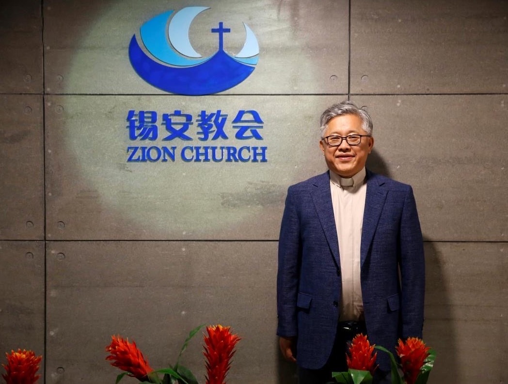 China releases detained Christian pastor Ezra Jin Mingri – #Catholic – China has freed underground Christian pastor Ezra Jin Mingri about two months after President Donald Trump publicly called for his release.Jin, who was arrested by Chinese authorities on Oct. 10, 2025, was reunited with his family in Los Angeles on July 3 ahead of America 250 celebrations.“I am profoundly grateful that Pastor Ezra Jin has been released and reunited with his family,” Rep. Chris Smith, R-New Jersey, a Catholic, said in a July 5 statement. “I especially thank President Trump for personally raising Pastor Jin’s case with CCP [Chinese Communist Party] General Secretary Xi Jinping and for ensuring that U.S. diplomats remained committed in pressing for his freedom.”Trump said following his visit to China in May that President Xi Jinping was “giving very serious consideration to the pastor,” referring to Jin. Congress had urged Trump to use the U.S.-China summit to advocate for Jin’s release alongside Jimmy Lai, the jailed Catholic media tycoon and democracy advocate. Trump noted China’s president was less likely to release Lai.A statement issued to reporters by the pastor’s family said: “We truly witnessed a miracle and we are feeling so overwhelmed with joy. We thank God for this tremendous miracle. We also thank President Trump and his administration for their tremendous leadership. We hope this is a signal of a positive turn for people of faith in China and relations between our two nations.”Jin was among nearly 30 people arrested by Chinese Communist Party authorities during a sweeping crackdown across nine cities on the underground Zion Church, of which he is the founder.Frances Hui, policy and advocacy manager at the Committee for Freedom in Hong Kong Foundation, wrote on social media: “Incredible to hear that [Jin] is free, has just arrived in L.A., and is finally reunited with his family.” Hui was among advocates who rallied on behalf of those imprisoned in China ahead of Trump’s visit.Hui described standing beside Jin’s daughter, Grace Jin Drexel, as “a privilege,” noting that she and her husband, Bill Drexel, had advocated for Jin’s release while preparing for the birth of their third child.Senate Foreign Relations Committee Chair Sen. Jim Risch, R-Idaho, said in a statement: “Despite months of imprisonment, Pastor Jin stayed true to his faith. Yet again, President Trump has demonstrated his ability to stand up for persecuted Christians worldwide.”Former vice president Mike Pence said in a statement: “President Trump should be commended for securing Ezra Jin’s release by raising the case with Xi Jinping in Beijing this year. Truly treasure in heaven to see this godly man of faith set free.”
