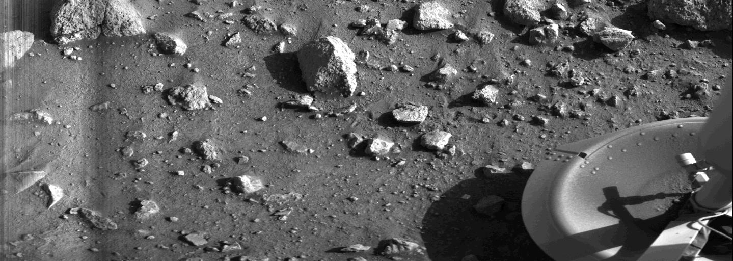 Our First View of the Surface of Mars – On the morning of July 20, 1976, roughly 40 minutes after mission controllers received word that the Viking 1 lander had successfully touched down on the surface of Mars, this photo gave us our first view from the surface of another planet. Our First View of the Surface of Mars – On the morning of July 20, 1976, roughly 40 minutes after mission controllers received word that the Viking 1 lander had successfully touched down on the surface of Mars, this photo gave us our first view from the surface of another planet.