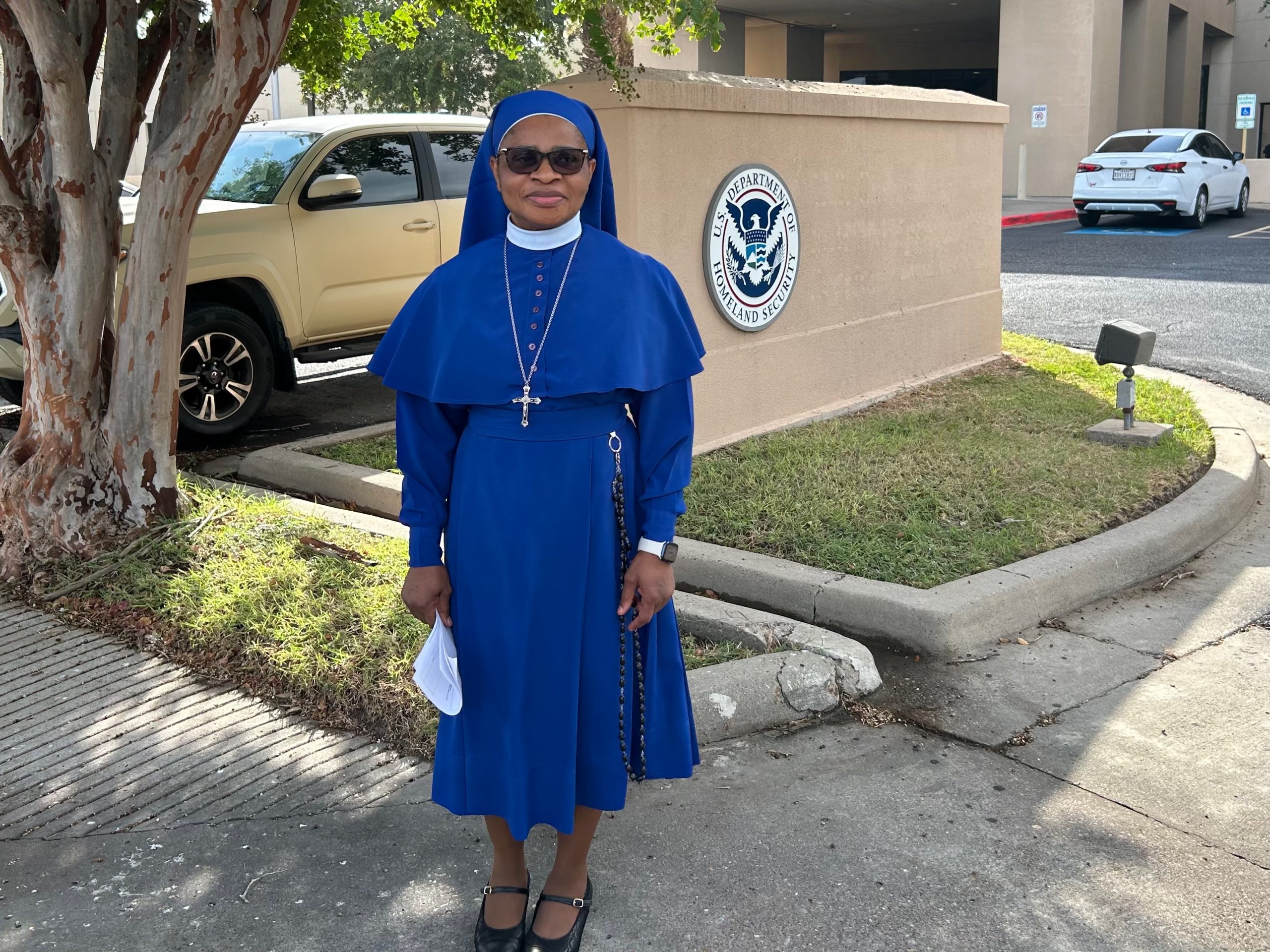 South Texas nun still at risk of third-country removal following ICE check-in, attorney says - #Catholic - HARLINGEN, Texas — In the most recent development in an immigration case that has gained national attention, Sister Leticia Ugboaja, the Nigerian Catholic nun and nurse who was briefly detained by Immigration and Customs Enforcement (ICE) agents in south Texas in June, was informed today that third-country removal was not off the table, which her attorney called “very concerning.”After a July 28 check-in with ICE officials in Harlingen, Texas, Carlos M. Garcia, Ugboaja’s lawyer, told reporters gathered outside the ICE field office that the possibility of third-country removal “is very concerning for us ... That is obviously not what we want. And that’s why we are exploring all our legal alternatives.”Garcia said he and his client have not yet decided on a specific legal path.At a July 23 press conference, he said an immigration judge denied Ugboaja’s application for asylum in 2019 but did grant her protection from removal to Nigeria under the United Nations Convention Against Torture, finding it was likely she would be tortured if she returned there.Garcia said this protection legally bars the U.S. government from deporting her to Nigeria, though she remains under a final order of removal and could be sent to a third country.After Ugboaja’s July 28 check-in, her attorney expressed gratitude that the nun, who has lived in the United States for nearly two decades and has never missed an immigration appointment, was not detained and not required to wear an ankle monitor, possibilities he discussed last week. The nun has another check-in scheduled for Jan. 28, 2027.“We’re happy that she’s continuing to be able to live her life the way she’s been living it, which is a life of service to the community and to her church family,” Garcia said.“Today was just a check-in,” he said, and ICE officials “determined that [Ugboaja] was able to continue [living] based on the conditions that they had given her before, which is really released on her own word, her own recognizance.”Ugboaja, a member of the Daughters of Mary Mother of Mercy and a registered nurse at South Texas Health System, was detained by two ICE agents on Sunday, June 28, as she walked to Mass at a church where she serves as a Eucharistic minister.At a press conference last week, the only time she has spoken publicly, she described weeks of “stress, anxiety, and fear” since the detainment.Though she has felt afraid and hurt, she said she has been trusting in God, quoting Jesus’ admonition to “not be afraid, because I am with you always.”The nun declined to speak with reporters after her check-in July 28.Sister Norma Pimentel, executive director of Catholic Charities of the Rio Grande Valley and a member of the Missionaries of Jesus in the Diocese of Brownsville, Texas, told EWTN News this process has been very difficult for Ugboaja.“She’s such a joyful, happy, and beautiful personality,” Pimentel said. “She goes to daily Mass, and receiving the Eucharist is so much a part of her strength and her force within her, but this disruption has scared her tremendously.”Though Ugboaja was released the same day she was detained, in part through the efforts of Rep. Henry Cuellar, D-Texas, Pimentel said “it was a tough time for her to be in detention … it felt like an eternity for her.”
 
 Sister Norma Pimentel hugs Sister Leticia Ugboaja outside the ICE field office in Harlingen, Texas, before Ugboaja’s July 28, 2026, immigration check-in. | Credit: Amira Abuzeid/EWTN News
 
 Pimentel said the nun “just broke down into tears, uncontrollably” upon her release.Since then, the community has poured out its support, Pimentel said. During this morningʼs check-in at the ICE field office, Father Isaac E. Erondu, a priest from Mission, Texas, led a group of people, including Ugboaja, in prayer before she entered the building with her lawyer.TweetSupporters then prayed the rosary together as they awaited news of Ugboaja’s fate.
 
 Supporters of Sister Leticia Ugboaja, including Sister Norma Pimentel, right, pray the rosary outside an ICE field office in Harlingen, Texas, as they await news of Ugboaja’s immigration case, July 28, 2026. | Credit: Amira Abuzeid/EWTN News
 
 “She’s trying to be strong,” Pimentel said. “She wants to continue just being herself … In seeing the support, the love, and so many people that are here for her, she knows she’s not alone.”We want her to know “we are here with you, and you’ll be OK,” she said.
 
 We were all thinking this was about picking up criminals, but there’s no criminal sense in all of this.”
 
 Sister Norma Pimentel
 
 
 In a message to Catholics and other supporters concerned with Ugboaja’s case, as well as the nature of ICE’s recent immigration enforcement measures, Pimentel, who has worked on behalf of immigrants on the U.S.-Mexico border for more than 20 years, said: “I think that we must stand together strong, supporting the defense of good people that are here in our community … and not only [Ugboaja], but everybody, so many families who are hurting.”“We must speak up and ask for … a process that is more respectful to human life and to the goodness of people,” she continued. “So many people are here in the community and are really contributing in a positive, good way. This should not be happening.”Of ICE’s enforcement measures, Pimentel said: “We were all thinking this was about picking up criminals, but there’s no criminal sense in all of this, you know? And so all of us must truly stand up and defend the right way of who we are as Americans here in the United States.”