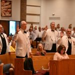 State Knights officers installed amid significant membership growth #Catholic - A Catholic from the Paterson Diocese led the installation of State officers of the N.J. State Knights of Columbus for the 2026-27 fraternal year on July 18, 2026, during a Mass held at St. Jude Thaddeus Church in the Budd Lake neighborhood of Mount Olive Township, N.J. During the last fraternal year, the N.J. State Knights notched a record, adding 2,754 men to the membership rolls — the best in 26 years.
James P. Sweeney of the Paterson Diocese was also installed for his second year of a two-year term as State Deputy. He belongs to St. Jude Parish in Mount Olive and is a member of the Knights of Columbus Father Joseph A. Cassidy Council 6100. Sweeney also sits on the board of trustees of diocesan Catholic Charities and the diocesan Pastoral Council led by Bishop Kevin J. Sweeney, who was the main celebrant and homilist of the installation Mass.
The following remaining State Knights officers were installed that day: Father Ernest G. Rush, State Chaplain, who is pastor of Our Lady of Mount Carmel Parish in Lyndhurst; Russell D. Petrocelli, State Secretary, from the Newark Archdiocese; Scott C. Williams, State Treasurer, from the Metuchen Diocese; Edward V. Michalak, State Advocate, from the Trenton Diocese; and Christopher A. Tomasello, Sr., State Warden, from the Camden Diocese.
During the 2025-26 fraternal year, the State Knights, which oversees 350 councils with a total membership of more than 60,000 Catholic men, also expanded its Evangelization and Faith Formation program throughout the state. This includes Cor program, named after the Latin word for “heart” and the root of “courage,” It features 60- to 90-minute monthly or bi-monthly gatherings focused on three pillars: prayer, formation, and fraternity. Men gather periodically to “discuss their faith and how it impacts their daily lives,” Sweeney said.

Click here to subscribe to our weekly newsletter.

“There has been a resurgence of men in our parishes looking to grow in their faith. The Knights is a perfect place for them. We create a community where men can share their faith and then put their faith into action,” said Sweeney. He continued to say, “We are the right faith organization at the right time, offering every Catholic gentleman the opportunity to become a Knight”.
These young men might be attracted to the Knights because they live their “faith in action” across New Jersey, supporting numerous charities, Sweeney said. Among them are a few in the Paterson Diocese, including the support of the Catholic Charities Department of Persons with Disabilities support through the Intellectual Disabilities drive. They also support the Coats-for-Kids drive, where the Knights in conjunction with the Cathedral of St John the Baptist in Paterson, N.J., give an average of more than 2,000 coats, at the “Bethlehem in Paterson,” an annual Christmas charity event at the Cathedral.
The installation liturgy began with Knights of Columbus Color Corp from throughout the state leading a procession of the NJ State Council leaders and clergy down the center aisle of St. Jude’s Church, wearing crisp blue uniforms and white gloves and holding ceremonial swords and flags.
Concelebrating the installation Mass were Bishop Emeritus Paul G. Bootkoski of the Metuchen Diocese, who is now State Chaplain Emeritus; Father Ernest Rush State Chaplain; Father J. Antonio Gaviria, pastor of St. Jude’s; Father William Smith, a retired priest of the Metuchen Diocese; and Msgr. Geno Sylva, rector of St. John’s and diocesan vicar for special projects.
The State Knights hold an annual State Officers/District Deputies Installation ceremony to install the newly elected state-level officers for the upcoming fraternal year. The ceremony marks the start of the Columbian Year for the organization. The officers’ family and friends attended the liturgy as a sign of support.
A banquet followed the July 20 installation Mass.
BEACON PHOTOS | JOE GIGLI
 [See image gallery at beaconnj.org] &nbsp;