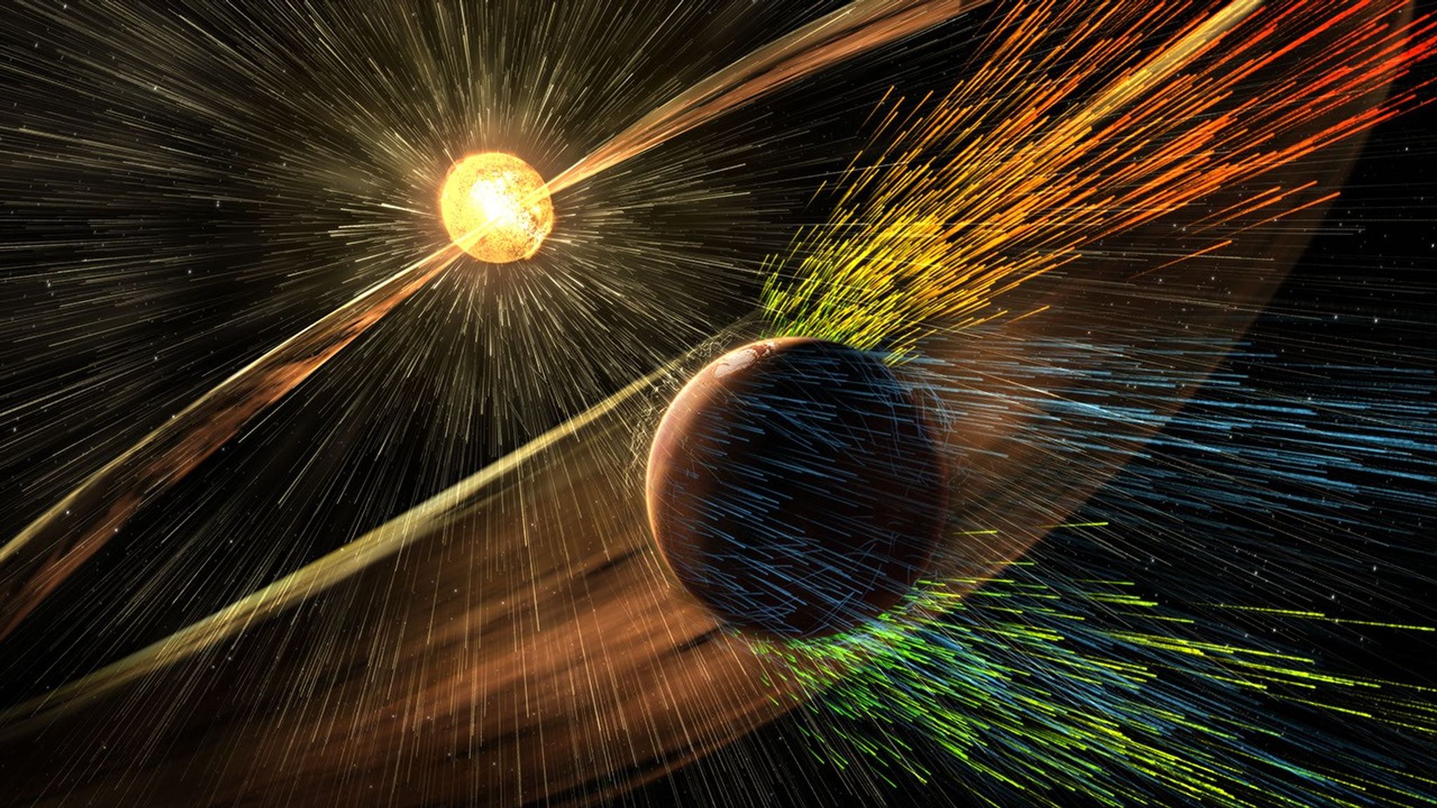 Understanding How Martian Auroras Are Made – This illustration depicts charged particles from a solar storm stripping away charged particles of Mars’ atmosphere, one of the processes of Martian atmosphere loss studied by NASA’s MAVEN mission. Understanding How Martian Auroras Are Made – This illustration depicts charged particles from a solar storm stripping away charged particles of Mars’ atmosphere, one of the processes of Martian atmosphere loss studied by NASA’s MAVEN mission.