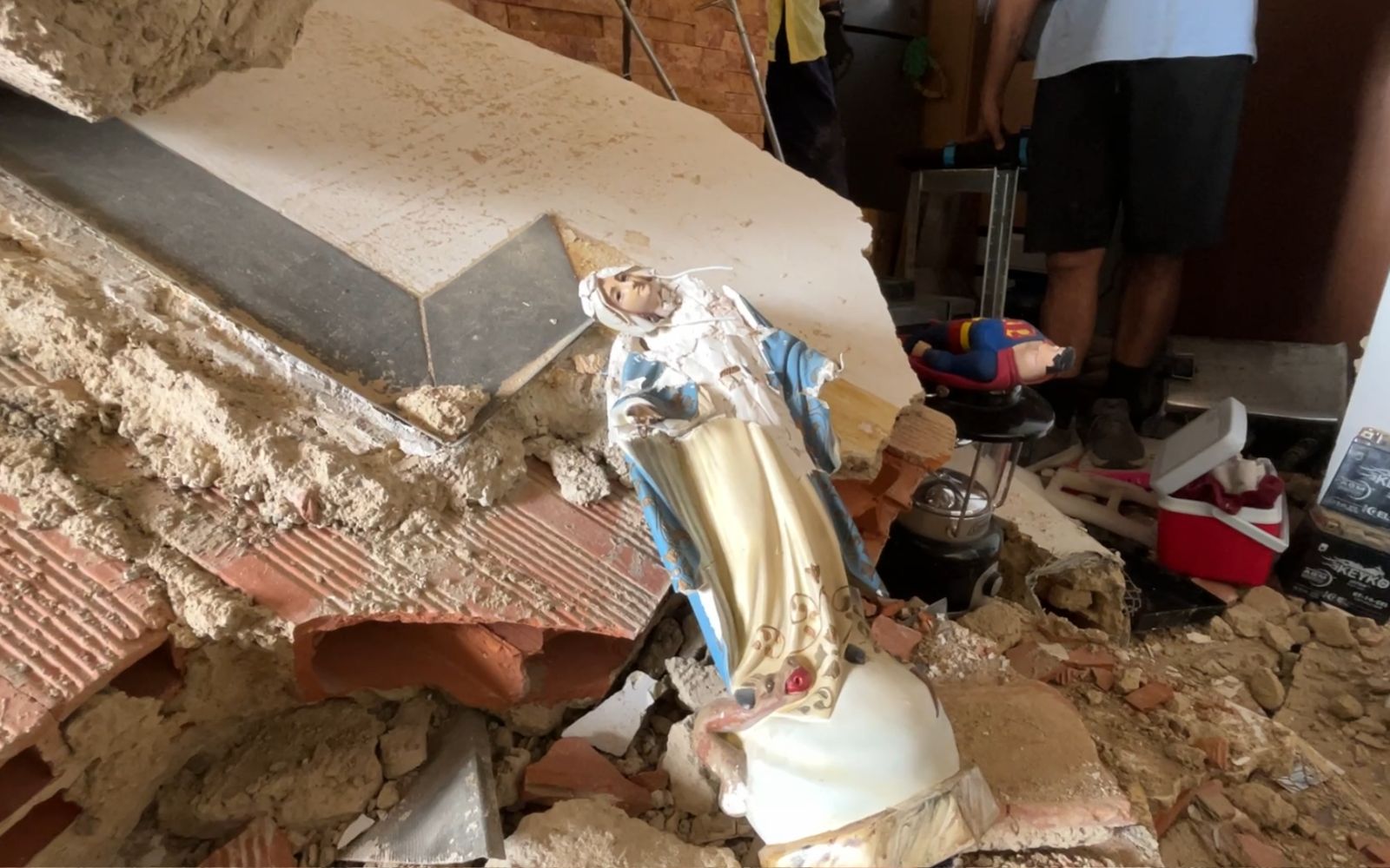 Where is God in the midst of tragedy? A bishop responds following Venezuela earthquakes – #Catholic – How can you find God amid tragedy? Why does God allow so much suffering? These are questions people might be asking themselves in Venezuela following the earthquakes of June 24.Carlos Márquez, auxiliary bishop of Caracas, reflected on the mystery of suffering in an interview with ACI Prensa, the Spanish-language sister service of EWTN News. In the prelateʼs view, the Catholic Church plays a fundamental role in shedding light on these existential questions.A promise to hold onto: ‘We are not alone’Márquez said it would be “an act of tremendous pridefulness” to attempt to provide answers that fully resolve this mystery. Ultimately, he noted, asking these questions is a way of “looking for someone to blame.” They are questions that “paralyze us and fill us with bitterness and pain.”“We can’t escape biological law; we can’t escape the laws of nature. What we once thought was a curse or divine punishment, we now know to be natural processes, processes that are even necessary,” he explained regarding the devastating earthquakes.To help make sense of the tragedy, Márquez pointed to two specific factors. The first is human freedom, which, when misused, “causes suffering and pain.” He referred to the collapsed buildings, many of which might have been built in unsuitable locations due to poor ground conditions or perhaps constructed without adhering to proper safety standards.“Imprudence, whether culpable or not, always ends in tragedy. This is not caused, desired, or much less ordained by God. It’s not the divine will,” he remarked.Márquez identified the second specific element in St. Paul’s Letter to the Romans, where the apostle to the Gentiles wrote that creation “groans until the present and suffers the pains of childbirth” (Rom 8:22-39).This helps us understand that nature “readjusts, evolves, and moves” as part of a process “toward the fullness promised by Jesus Christ.” The auxiliary bishop explained that creation “will be subject to pain” until it is recapitulated in Christ, and we, as creatures, undergo these vicissitudes.“Therefore, on our journey toward the fullness of living happily forever with Christ in heaven, we will encounter pain and suffering,” Márquez noted.Yet in the face of these realities, the prelate offered a reassuring promise: “Christ’s promise was not that we would not suffer, nor that there would be no earthquakes, floods, or natural tragedies. Amid the pain, he promised not to abandon us. We are not alone: ‘I will be with you until the end of the world.’ He promises us his companionship in the midst of pain.”The Lord “walks with us in the midst of our pain” and fulfills his promise “through his Church, among those who suffer.” The sacraments and the word, he continued, comfort and heal us, and transform our hearts “so we can move forward.”God also gives us the example and intercession of the saints “so that we do not lose heart” and might feel accompanied. “When one is in great pain, when one is suffering deeply, the tragedy becomes worse when we are alone and isolated,” he said.Christian hope in the face of death and tragedyIn recent weeks, the most heart-wrenching stories have filled social media. Yet, for the most part, they share a fundamental element highlighted by Márquez: hope.Many people are thanking God for being alive and, amid unimaginable suffering, affirming that they will live to honor their deceased loved ones and will spare no effort to discover the purpose for which God has saved them.“If we live united with Christ in suffering, we will live with him forever in heaven. Death does not have the final word. This earthquake does not have the final word. God has the final word, which is a word of life, happiness, and eternal joy,” he stated.So, what is required of those Venezuelans who remain? Márquez answered clearly: to follow the example of all their saintly compatriots, to face adversity without asking “why,” and to work so that the future may be better.
Carlos Márquez, auxiliary bishop of Caracas, left, with people affected by the June 24, 2026, earthquakes in Venezuela. | Credit: Photo courtesy of Bishop Carlos Márquez
“Pain is fleeting; death is not final. United in faith, hope, and charity, with our eyes fixed on the risen Christ, we walk together in communion to overcome this tragedy,” Márquez said.“Venezuela is a land of grace; Venezuela is a land of saints. We have hope, and we will rise again. We will rise from the dust of this earthquake,” he added.Finally, he recalled the words St. John Paul II spoke at the Teresa Carreño Theater in Caracas during his second visit to the country on Feb. 10, 1996: “Venezuelans, even though the difficulties are serious and the challenges immense, your resolve must be great. Faced with a present full of uncertainty and a future full of questions, put your abilities to use with imagination and, above all, with generosity, trusting in God: God loves mankind.”As of now, the official death toll following the earthquakes stands at 4,829, while the number of injured and affected people runs into the tens of thousands.This story was first published by ACI Prensa, the Spanish-language sister service of EWTN News. It has been translated and adapted by EWTN News English. Where is God in the midst of tragedy? A bishop responds following Venezuela earthquakes – #Catholic – How can you find God amid tragedy? Why does God allow so much suffering? These are questions people might be asking themselves in Venezuela following the earthquakes of June 24.Carlos Márquez, auxiliary bishop of Caracas, reflected on the mystery of suffering in an interview with ACI Prensa, the Spanish-language sister service of EWTN News. In the prelateʼs view, the Catholic Church plays a fundamental role in shedding light on these existential questions.A promise to hold onto: ‘We are not alone’Márquez said it would be “an act of tremendous pridefulness” to attempt to provide answers that fully resolve this mystery. Ultimately, he noted, asking these questions is a way of “looking for someone to blame.” They are questions that “paralyze us and fill us with bitterness and pain.”“We can’t escape biological law; we can’t escape the laws of nature. What we once thought was a curse or divine punishment, we now know to be natural processes, processes that are even necessary,” he explained regarding the devastating earthquakes.To help make sense of the tragedy, Márquez pointed to two specific factors. The first is human freedom, which, when misused, “causes suffering and pain.” He referred to the collapsed buildings, many of which might have been built in unsuitable locations due to poor ground conditions or perhaps constructed without adhering to proper safety standards.“Imprudence, whether culpable or not, always ends in tragedy. This is not caused, desired, or much less ordained by God. It’s not the divine will,” he remarked.Márquez identified the second specific element in St. Paul’s Letter to the Romans, where the apostle to the Gentiles wrote that creation “groans until the present and suffers the pains of childbirth” (Rom 8:22-39).This helps us understand that nature “readjusts, evolves, and moves” as part of a process “toward the fullness promised by Jesus Christ.” The auxiliary bishop explained that creation “will be subject to pain” until it is recapitulated in Christ, and we, as creatures, undergo these vicissitudes.“Therefore, on our journey toward the fullness of living happily forever with Christ in heaven, we will encounter pain and suffering,” Márquez noted.Yet in the face of these realities, the prelate offered a reassuring promise: “Christ’s promise was not that we would not suffer, nor that there would be no earthquakes, floods, or natural tragedies. Amid the pain, he promised not to abandon us. We are not alone: ‘I will be with you until the end of the world.’ He promises us his companionship in the midst of pain.”The Lord “walks with us in the midst of our pain” and fulfills his promise “through his Church, among those who suffer.” The sacraments and the word, he continued, comfort and heal us, and transform our hearts “so we can move forward.”God also gives us the example and intercession of the saints “so that we do not lose heart” and might feel accompanied. “When one is in great pain, when one is suffering deeply, the tragedy becomes worse when we are alone and isolated,” he said.Christian hope in the face of death and tragedyIn recent weeks, the most heart-wrenching stories have filled social media. Yet, for the most part, they share a fundamental element highlighted by Márquez: hope.Many people are thanking God for being alive and, amid unimaginable suffering, affirming that they will live to honor their deceased loved ones and will spare no effort to discover the purpose for which God has saved them.“If we live united with Christ in suffering, we will live with him forever in heaven. Death does not have the final word. This earthquake does not have the final word. God has the final word, which is a word of life, happiness, and eternal joy,” he stated.So, what is required of those Venezuelans who remain? Márquez answered clearly: to follow the example of all their saintly compatriots, to face adversity without asking “why,” and to work so that the future may be better.
Carlos Márquez, auxiliary bishop of Caracas, left, with people affected by the June 24, 2026, earthquakes in Venezuela. | Credit: Photo courtesy of Bishop Carlos Márquez
“Pain is fleeting; death is not final. United in faith, hope, and charity, with our eyes fixed on the risen Christ, we walk together in communion to overcome this tragedy,” Márquez said.“Venezuela is a land of grace; Venezuela is a land of saints. We have hope, and we will rise again. We will rise from the dust of this earthquake,” he added.Finally, he recalled the words St. John Paul II spoke at the Teresa Carreño Theater in Caracas during his second visit to the country on Feb. 10, 1996: “Venezuelans, even though the difficulties are serious and the challenges immense, your resolve must be great. Faced with a present full of uncertainty and a future full of questions, put your abilities to use with imagination and, above all, with generosity, trusting in God: God loves mankind.”As of now, the official death toll following the earthquakes stands at 4,829, while the number of injured and affected people runs into the tens of thousands.This story was first published by ACI Prensa, the Spanish-language sister service of EWTN News. It has been translated and adapted by EWTN News English.