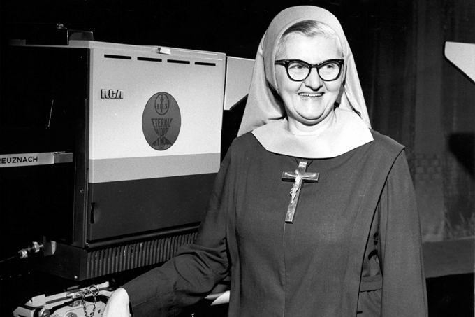 45 years after its first broadcast, EWTN has become the largest Catholic media network in the world – #Catholic – Forty-five years ago today, Mother Mary Angelica of the Annunciation launched the first broadcast of the Eternal Word Television Network (EWTN) from a converted garage in Alabama. What began as a humble television venture would grow into the world’s largest Catholic media network.With 0 and 12 nuns with no television experience, Mother Angelica turned the monastery garage into a television studio. EWTN received its Federal Communications Commission license on Jan. 27, 1981, making it the first Catholic satellite television station in the United States.Just a few months later, on Aug. 15, 1981, EWTN began broadcasting four hours a day to 60,000 homes.The anniversary, Aug. 15, also marks the feast of the Assumption, a solemnity commemorating the end of the Virgin Mary’s earthly life and her assumption, body and soul, into heaven.As EWTN commemorates 45 years of spreading the Eternal Word, here’s a look back at the work and progress of the organization that all started with the mission of one cloistered nun.EWTN starts growing rapidlyIn 1983, the network launched its flagship talk show, “Mother Angelica Live.” Despite innumerable challenges and millions in debt, the network grew, supported only by viewer contributions.Around the same time, cable channels began to pick up EWTN. Within a short period, the network went from tens of thousands of homes to hundreds of thousands.It quickly expanded from the original four hours of broadcasting to all day content. In 1987, programming expanded to a 24-hour daily schedule, reaching 10 million American subscribers.EWTN branched out of television by launching a worldwide shortwave radio service in 1992. Its worldwide AM/FM radio services began just four years later.Soon the network started establishing a global presence. In 1995, EWTN launched its first international television service for Latin America. That same year, the network provided live coverage of Pope Saint John Paul II’s visit to the U.S., in both English and Spanish, on television and radio. By 1996 EWTN programming was also reaching Europe and the Pacific Rim, including Australia, New Zealand, China, Japan, and the Philippines. A big year for the network, 1996 also marked when EWTN.com went live. In 1998, EWTN launched satellite television service to Africa. By 2009, the network was reaching the extraordinary number of 150 million television homes.The vast expansion marked an important transition from an American Catholic television network to an international Catholic media network, which would continue to grow in the years to come.Expansion to print and digital mediaMother Angelicaʼs early series of small pamphlets and books eventually grew into electronic and print news services. In 2011, the network acquired The National Catholic Register, one of the countryʼs oldest Catholic newspapers.The acquisition was part of a broader effort to expand EWTNʼs presence in Catholic journalism.EWTN continued this effort when it launched “EWTN News Nightly” in 2013, a daily television news program from Washington, D.C. This was significant because it moved EWTN further into daily news production rather than religious programming and coverage of Church events.In 2014, EWTN acquired Catholic News Agency as well as its Spanish-language sister agency, ACI Prensa. Today, EWTN News includes agencies covering global Catholic news in Spanish, Italian, German, Portuguese, French, English, and Arabic.In 2026, EWTN News announced a rebrand and is currently in the process of bringing most of its news entities — print, digital, and broadcast — under the global brand of EWTN News. EWTN moves forwardForty-five years later, EWTN is now reaching more than 435 million television households across more than 160 countries and territories. The recently established EWTN Studios continues the EWTN legacy of developing the most impactful content in the Catholic space, and EWTN Digital is building the platforms to distribute EWTN Studios content to new generations. EWTN Radio reaches a global audience through more than 500 domestic and international AM and FM radio affiliates, satellite radio, and digital streaming platforms.EWTN Publishing publishes books in both print and electronic form to a worldwide audience and has now released around 100 books by renowned Catholic authors who have profoundly influenced the faithful.Through live coverage, documentaries, and more, EWTN has covered four pontificates and numerous historic Church events and has shared the lives and faith of Catholics across the globe. It also reaches millions of online users through its social media including its presence on X, Instagram, Facebook, and YouTube.EWTN’s story began with a television network and continues to be guided by Mother Angelicaʼs vision of using modern technology to share the Gospel of Jesus Christ and truths of the Catholic faith with millions around the world.