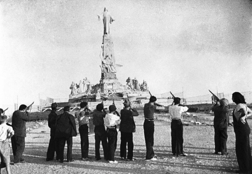 Aug. 7 marks 90th anniversary of Spanish ‘execution’ of Sacred Heart of Jesus statue – #Catholic – Aug. 7 marks the 90th anniversary of the day when militiamen from the Popular Front, one of the factions in the Spanish Civil War, fired upon the monument to the Sacred Heart of Jesus, before which King Alfonso XIII in 1919 had consecrated Spain.The original monument, the work of architect Carlos Maura and sculptor Aniceto Marinas, was built on the Cerro de los Ángeles, the geographical center of Spain, and was funded through public subscription, although the statue itself was donated by the count of Guaqui, Juan Marino de Goyeneche.The monumental complex, standing 92 feet tall, consisted not only of the central figure of Jesus Christ but also of two sculptural groups representing, respectively, sanctified humanity and humanity journeying toward holiness.The first group featured St. Margaret Mary Alacoque, St. Augustine, St. Francis of Assisi, St. Teresa of Jesus, Blessed Bernardo de Hoyos, and St. John the Evangelist, among others. The second group comprised figures representing the path of charity, virtue, and the love essential for conversion and sanctification.Its inauguration, originally scheduled for 1918, was postponed due to the Spanish flu pandemic until May 30, 1919. It was then that, in the presence of the government, the apostolic nuncio, Archbishop Francesco Ragonesi, and a large group of bishops and cardinals, Alfonso XIII pronounced the formula for the consecration of Spain to the Sacred Heart: “Spain, the people of your heritage and predilection, bows reverently today before that throne of goodness raised for you in the heart of the peninsula. Reign in the hearts of men, in the bosom of our homes, in the minds of the wise, in the halls of science and letters, and in our laws and national institutions.”
 
 At the foot of the Sacred Heart of Jesus statue, in 1919 King Alfonso XIII pronounces the formula of consecration of Spain to the Sacred Heart of Jesus. | Credit: Public domain
 
 Tried, shot by firing squad, and blown up with dynamiteThe Spanish Civil War broke out on July 18, 1936. Just five days later, five young men who had remained near the monument to defend it against potential desecration were killed.On Aug. 7, the first Friday of the month, Popular Front militiamen staged a mock summary trial of Jesus; after passing sentence, they fired upon the monument while shouting, “Aim with hatred! Fire with rage!”They subsequently attempted to topple and demolish the monument using various tools, including cables and sledgehammers, but failed. They then decided to blow it up with dynamite. They subsequently dragged the head of the Christ figure behind a horse to further humiliate the image.The site, renamed Cerro Rojo (Red Hill), was retaken by Nationalist forces on Nov. 6, 1936, which was another first Friday of the month. Troops under the command of Gen. José Enrique Varela attended a Mass of reparation officiated by a military chaplain.New monumentFollowing the end of the Civil War in 1939, reconstruction of the site began in 1944. This coincided with the 25th anniversary of the consecration of Spain, an occasion for which the Holy See had granted a jubilee year.The sculptor of the original work was engaged for the 38-foot-tall statue of the Sacred Heart, which stands atop an 85-foot pedestal. 
 
 The inscriptions that appear on the foundation of the monument to the Sacred Heart of Jesus in Spain. | Credit: Photo courtesy of the Diocese of Getafe
 
 Four sculptural groups by Fernando Cruz were placed around the base. The first group, representing “Missionary Spain,” features Isabella the Catholic, Christopher Columbus, Hernán Cortés, and St. Junípero Serra. The second group, representing “Spain: Defender of the Faith,” includes Bishop Osio of Córdoba, Don Pelayo, Diego Laínez, John of Austria, and Blessed Anselmo Polanco, a bishop martyred during the war.The third group, dedicated to the Church militant, consists of figures representing charity, virtue, and love. The final sculptural ensemble, representing the Church triumphant, reproduces the saints from the original monument.The new monument, inaugurated in 1965, is located on the site of the original, the ruins of which are preserved on the other side of the complexʼs large esplanade. Ten years later, a sanctuary was inaugurated featuring a temple carved into the rock.This story was first published by ACI Prensa, the Spanish-language sister service of EWTN News. It has been translated and adapted by EWTN News English.