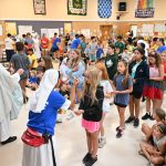 Camp Auxilium children smile as bishop makes inaugural visit #Catholic - Bishop Kevin J. Sweeney made history on July 24, visiting Camp Auxilium, a summer day camp for boys and girls in Newton, N.J., for the first time and celebrating Mass for enthusiastic staff, campers, and their families during the camp’s Family Day.
That day, Bishop Sweeney delighted in meeting and talking with members of the Camp Auxilium family and receiving a tour of the facility and the various activity areas. The Salesian Sisters of St. Don Bosco, also known as the Daughters of Mary Help of Christians, run the camp, which is located in rural Sussex County.
Activities at Camp Auxilium include swimming and swim instruction, archery, boating and kayaking, mini-golf, low- and mid-ropes courses, arts and crafts, sports, and drama. The Salesian Sisters are assisted by Red Cross-certified lifeguards, counselors, and activity specialists.
The Boys Camp accepts campers who were 4 years old by October of last year through those who have completed 6th grade. Girls Camp accepts campers who were 4 years old by October of last year through those who have completed 8th grade. This year, Camp Auxilium welcomed 225 campers over its five weeks in operation.
BEACON PHOTOS | JOE GIGLI
 [See image gallery at beaconnj.org] &nbsp;

Click here to subscribe to our weekly newsletter.