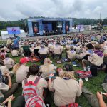 In West Virginia mountains, over 2,000 Catholic Scouts gather for Mass ‘filled with joy, hope’ #Catholic – (OSV News) — Every four years, thousands of Catholic Scouts from across the U.S. gather for Sunday Mass in the mountains of West Virginia.
As faith is the first of the core principles which they hold dear, they joyfully observe their Sunday obligation while participating in the Scouting America National Jamboree at the Summit Bechtel Reserve in Mount Hope, W.Va., which was held this year July 22-31.
“It was a wonderful Mass filled with joy, with hope,” said Bishop Evelio Menjívar of Wheeling-Charleston, who celebrated the July 26 Mass for more than 2,000 Catholic Scouts who filled a field at the reserve that morning. “For the church, seeing so many young people is always a sign of hope.” The Scouts, he said, are devout, willing to serve and pledge to honor God and country.
“It is just beautiful,” Bishop Menjívar told The Catholic Spirit, the news outlet of the Diocese of Wheeling-Charleston.
The Catholic Scouts were among the more than 20,000 Scouts from throughout the country who attended the nine-day jamboree, which is held every four years at the reserve.
Click here to subscribe to our weekly newsletter.
Concelebrating the Mass and giving the homily was Bishop Michael W. Fisher of Buffalo, New York, the U.S. Conference of Catholic Bishops’ episcopal liaison to Catholic Scouting America, which is the largest of the faith-based Scouting America groups.
A Scout is reverent, Bishop Fisher said in his homily. “That’s what brings us here today as God’s people,” he said, “to give thanks, to give prayer and to offer that ultimate prayer in this holy Eucharist.”
Scouts, he said, are first reverent to God; faithful in his or her religious duties; and respect the convictions of others in matters of religion and custom.
Noting that they were surrounded by God’s beauty and creation, Bishop Fisher told the Scouts that reverence comes naturally to human beings and, in a particular way, to Catholics.
“When we look at the mountains and forests,” he said, “we can’t help but praise our creator. For truly we are in God’s country.”
In the Gospel for the Mass (Mt 13:44-52), Bishop Fisher said that Jesus reminds us that reverence is about finding hidden treasure and gives numerous examples of those who are searching.
“It’s not just an outward posture, but it’s about being transformed internally in our hearts and in our souls,” he said.
In the Gospel, Jesus said to his disciples: “The kingdom of heaven is like a treasure buried in a field, which a person finds and hides again, and out of joy goes and sells all that he has and buys that field. Again, the kingdom of heaven is like a merchant searching for fine pearls. When he finds a pearl of great price, he goes and sells all that he has and buys it.”
A critical question to all, Bishop Fisher said, is: “What is that true treasure that you’re seeking in your life?”
To answer that, he pointed to the first reading (1 Kings 3:5, 7-12), where God appears to a young King Solomon in a dream and said, “Ask something of me and I will give it to you.”
Solomon doesn’t ask for riches, or a long life, or power over his enemies, Bishop Fisher said. Instead, he admits his limitations and says, “I am a mere youth, not knowing at all how to act.”
He asks God for an understanding heart, Bishop Fisher said, to discern between right and wrong. He asked for wisdom.
“This is exactly what we promise every time we stand at attention and make this Scout Sign, and repeat the Scout Oath,” Bishop Fisher said. “When we say we will do our duty to God and country and keep ourselves lawfully straight, we are asking for Solomon’s gift of wisdom. We are asking for a wise heart to navigate a complicated world.”
Bishop Fisher, an Eagle Scout himself, reminded all of the national jamboree’s theme, “Elevate,” and said that Jesus is calling all to elevate what they treasure in life.
“The treasure,” he said, “is God’s grace, his love and truth acting within us. To elevate means to stop digging for that cheap, temporary treasure like popularity or selfishness in material things,” he said. “Instead, hopefully, we sell out completely for what lasts: kindness, purity, reverence, and justice.”
A Scout who lives out the Scout Law is a living sign of God’s kingdom on earth, Bishop Fisher said. “Have you ever thought of yourself in that way?” he asked the Scouts.
In the second reading for the Mass, Bishop Fisher said that St. Paul reminds the Romans that we are called to be conformed to the image of God’s Son.
“Jesus is, you might say, that ultimate Scout leader,” Bishop Fisher said. “He did not come to be served, but to serve. He did a good turn daily. He prepared. He navigated the wilderness. He gathered a patrol of disciples. And he laid down his life to show that ultimate trail, that trail map to heaven.
“When you leave this jamboree and pack up your dirty laundry, your gear, and your cool patches, as well as great memories, the most important thing you should take home with you is a renewed spirit,” Bishop Fisher said. “God wants to elevate our character so that we become leaders and guides to others to what is right, and what is truly lasting in God’s kingdom.”
Jesus concludes the Gospel for the Mass with the warning about a net thrown into the sea that catches fish of every kind, Bishop Fisher said. At the end of the day, the good are gathered, he said, and the bad are thrown away. “Our lives are kind of like that net,” Bishop Fisher said. “Every day, we gather choices, words, and habits.”
He encouraged the Scouts to use the wisdom of Solomon, the great gift he asked for from the Lord, to sort through all of it and to be prepared. Bishop Fisher urged them to throw away gossip and dishonesty and keep the treasures of faith, service and the Scout spirit.
“Let us pray today for the courage to sell out for the kingdom of heaven, for the kingdom of God,” Bishop Fisher said, “to elevate our thoughts and actions, and to always seek the true treasure — a heart that knows, that loves, and serves God always. A Scout is reverent. Amen.”
The Catholic Scouts also prayed for the nation in the celebration of its 250th anniversary.
With them was Jesuit Father Mark Carr, national chaplain for Catholic Scouting America, who led the “Novena Prayer for America.”
Together, they prayed, “that the Church in the United States boldly proclaims the Gospel. May we all, especially our young Scouts, be joyful witnesses of Christ in our neighborhoods and schools.”
For more than 100 years, Catholic Scouting America has provided young people adventure, character building and values-based lessons grounded in the Catholic faith, the organization’s website states.
And this, Bishop Menjívar said, the church must continue to support.
“It’s a good place for children to learn and to grow, mature as a person but also in their faith and in their commitment to serve. I really encourage parents to look at those opportunities that the Scouts offer, especially at this time when we need to take the kids out of social media, the screens,” he said.
Colleen Rowan is executive editor of The Catholic Spirit, the news outlet of the Diocese of Wheeling-Charleston. This story was originally published by The Catholic Spirit and is distributed through a partnership with OSV News. For more information about Catholic Scouting America and to explore resources for parishes, families, and councils, visit CatholicScoutingAmerica.org.
In West Virginia mountains, over 2,000 Catholic Scouts gather for Mass ‘filled with joy, hope’ #Catholic – (OSV News) — Every four years, thousands of Catholic Scouts from across the U.S. gather for Sunday Mass in the mountains of West Virginia.
As faith is the first of the core principles which they hold dear, they joyfully observe their Sunday obligation while participating in the Scouting America National Jamboree at the Summit Bechtel Reserve in Mount Hope, W.Va., which was held this year July 22-31.
“It was a wonderful Mass filled with joy, with hope,” said Bishop Evelio Menjívar of Wheeling-Charleston, who celebrated the July 26 Mass for more than 2,000 Catholic Scouts who filled a field at the reserve that morning. “For the church, seeing so many young people is always a sign of hope.” The Scouts, he said, are devout, willing to serve and pledge to honor God and country.
“It is just beautiful,” Bishop Menjívar told The Catholic Spirit, the news outlet of the Diocese of Wheeling-Charleston.
The Catholic Scouts were among the more than 20,000 Scouts from throughout the country who attended the nine-day jamboree, which is held every four years at the reserve.
Click here to subscribe to our weekly newsletter.
Concelebrating the Mass and giving the homily was Bishop Michael W. Fisher of Buffalo, New York, the U.S. Conference of Catholic Bishops’ episcopal liaison to Catholic Scouting America, which is the largest of the faith-based Scouting America groups.
A Scout is reverent, Bishop Fisher said in his homily. “That’s what brings us here today as God’s people,” he said, “to give thanks, to give prayer and to offer that ultimate prayer in this holy Eucharist.”
Scouts, he said, are first reverent to God; faithful in his or her religious duties; and respect the convictions of others in matters of religion and custom.
Noting that they were surrounded by God’s beauty and creation, Bishop Fisher told the Scouts that reverence comes naturally to human beings and, in a particular way, to Catholics.
“When we look at the mountains and forests,” he said, “we can’t help but praise our creator. For truly we are in God’s country.”
In the Gospel for the Mass (Mt 13:44-52), Bishop Fisher said that Jesus reminds us that reverence is about finding hidden treasure and gives numerous examples of those who are searching.
“It’s not just an outward posture, but it’s about being transformed internally in our hearts and in our souls,” he said.
In the Gospel, Jesus said to his disciples: “The kingdom of heaven is like a treasure buried in a field, which a person finds and hides again, and out of joy goes and sells all that he has and buys that field. Again, the kingdom of heaven is like a merchant searching for fine pearls. When he finds a pearl of great price, he goes and sells all that he has and buys it.”
A critical question to all, Bishop Fisher said, is: “What is that true treasure that you’re seeking in your life?”
To answer that, he pointed to the first reading (1 Kings 3:5, 7-12), where God appears to a young King Solomon in a dream and said, “Ask something of me and I will give it to you.”
Solomon doesn’t ask for riches, or a long life, or power over his enemies, Bishop Fisher said. Instead, he admits his limitations and says, “I am a mere youth, not knowing at all how to act.”
He asks God for an understanding heart, Bishop Fisher said, to discern between right and wrong. He asked for wisdom.
“This is exactly what we promise every time we stand at attention and make this Scout Sign, and repeat the Scout Oath,” Bishop Fisher said. “When we say we will do our duty to God and country and keep ourselves lawfully straight, we are asking for Solomon’s gift of wisdom. We are asking for a wise heart to navigate a complicated world.”
Bishop Fisher, an Eagle Scout himself, reminded all of the national jamboree’s theme, “Elevate,” and said that Jesus is calling all to elevate what they treasure in life.
“The treasure,” he said, “is God’s grace, his love and truth acting within us. To elevate means to stop digging for that cheap, temporary treasure like popularity or selfishness in material things,” he said. “Instead, hopefully, we sell out completely for what lasts: kindness, purity, reverence, and justice.”
A Scout who lives out the Scout Law is a living sign of God’s kingdom on earth, Bishop Fisher said. “Have you ever thought of yourself in that way?” he asked the Scouts.
In the second reading for the Mass, Bishop Fisher said that St. Paul reminds the Romans that we are called to be conformed to the image of God’s Son.
“Jesus is, you might say, that ultimate Scout leader,” Bishop Fisher said. “He did not come to be served, but to serve. He did a good turn daily. He prepared. He navigated the wilderness. He gathered a patrol of disciples. And he laid down his life to show that ultimate trail, that trail map to heaven.
“When you leave this jamboree and pack up your dirty laundry, your gear, and your cool patches, as well as great memories, the most important thing you should take home with you is a renewed spirit,” Bishop Fisher said. “God wants to elevate our character so that we become leaders and guides to others to what is right, and what is truly lasting in God’s kingdom.”
Jesus concludes the Gospel for the Mass with the warning about a net thrown into the sea that catches fish of every kind, Bishop Fisher said. At the end of the day, the good are gathered, he said, and the bad are thrown away. “Our lives are kind of like that net,” Bishop Fisher said. “Every day, we gather choices, words, and habits.”
He encouraged the Scouts to use the wisdom of Solomon, the great gift he asked for from the Lord, to sort through all of it and to be prepared. Bishop Fisher urged them to throw away gossip and dishonesty and keep the treasures of faith, service and the Scout spirit.
“Let us pray today for the courage to sell out for the kingdom of heaven, for the kingdom of God,” Bishop Fisher said, “to elevate our thoughts and actions, and to always seek the true treasure — a heart that knows, that loves, and serves God always. A Scout is reverent. Amen.”
The Catholic Scouts also prayed for the nation in the celebration of its 250th anniversary.
With them was Jesuit Father Mark Carr, national chaplain for Catholic Scouting America, who led the “Novena Prayer for America.”
Together, they prayed, “that the Church in the United States boldly proclaims the Gospel. May we all, especially our young Scouts, be joyful witnesses of Christ in our neighborhoods and schools.”
For more than 100 years, Catholic Scouting America has provided young people adventure, character building and values-based lessons grounded in the Catholic faith, the organization’s website states.
And this, Bishop Menjívar said, the church must continue to support.
“It’s a good place for children to learn and to grow, mature as a person but also in their faith and in their commitment to serve. I really encourage parents to look at those opportunities that the Scouts offer, especially at this time when we need to take the kids out of social media, the screens,” he said.
Colleen Rowan is executive editor of The Catholic Spirit, the news outlet of the Diocese of Wheeling-Charleston. This story was originally published by The Catholic Spirit and is distributed through a partnership with OSV News. For more information about Catholic Scouting America and to explore resources for parishes, families, and councils, visit CatholicScoutingAmerica.org.