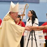 Paterson ministry event inspires Spanish faith servants, leaders #Catholic - On Aug. 1, the Spanish Catholic Charismatic Renewal of the Paterson Diocese, N.J., concluded its First Annual Diocesan Catholic Charismatic Servants Encounter (ECCADS) with a Spanish Mass celebrated by Bishop Kevin J. Sweeney. The event was held in the gym of St. Gerrard Majella School in Paterson, N.J.
Organized by diocesan Spanish Catholic Charismatic Renewal, ECCADS was designed for ministry servants and leaders, offering a day of formation, prayer, and spiritual renewal. The theme was “Servants Healed by Love, Formed to Serve, and Sent to Lead.”
The program included a series of talks focused on inner healing, the spirituality of Christian service, and developing the qualities needed to become effective leaders within their parish communities. Participants also took part in praise and worship, teaching, and Mass.
Bishop Sweeney served as the main celebrant and homilist of the Mass. Father Duberney Villamizar, diocesan vicar for Hispanic Affairs and pastor of St. Margaret of Scotland Parish in Morristown, N.J., concelebrated the Mass.
Among the participants of ECCADS were Teresa Amparo, general coordinator of Spanish Catholic Charismatic Renewal, and Marvin Nuñez, a singer-songwriter of faith-based music from the Dominican Republic.
Yessenia Castillo is the executive assistant to Father Duberney Villamizar, diocesan vicar for Hispanic Affairs and pastor of St. Margaret of Scotland Parish in Morristown, N.J.
BEACON PHOTOS | JOE GIGLI
 [See image gallery at beaconnj.org] 

Click here to subscribe to our weekly newsletter.

&nbsp;