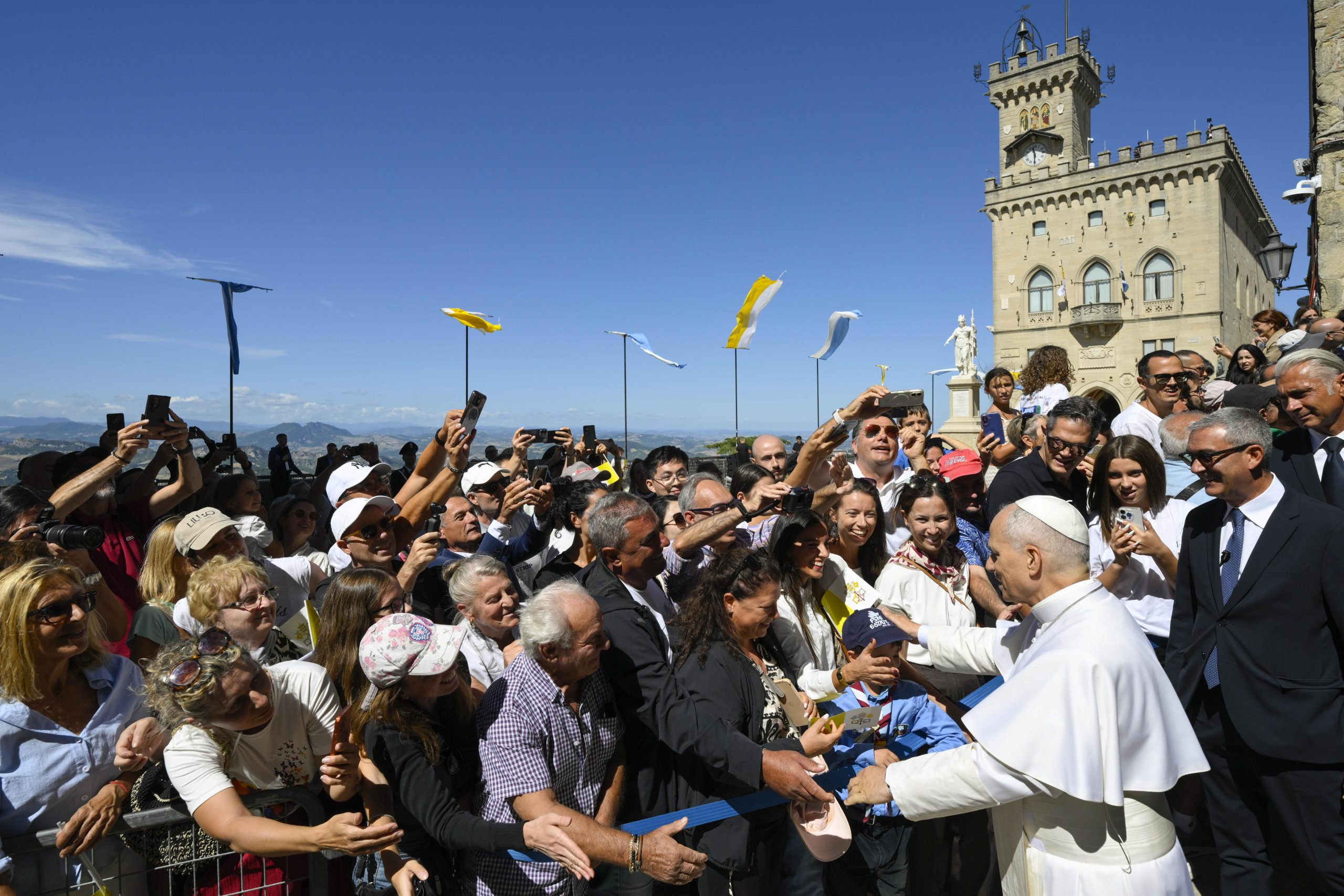 Pope Leo XIV visits San Marino, the oldest republic in the world and a ‘laboratory’ of good policies – #Catholic – Pope Leo XIV on Aug. 22 arrived in San Marino, launching a pastoral visit on the occasion of the country’s 100th anniversary of diplomatic relations with the Holy See. The Holy Father was also scheduled to visit the Italian city of Rimini, where the Meeting for Friendship Between Peoples takes place.The pope left Rome by helicopter around 8 a.m. and arrived 45 minutes later at the Torraccia airfield in San Marino. There he was received by the Captains Regent Alice Mina and Vladimiro Selva who were accompanied by various local officials.Also present in the welcome delegation was the apostolic nuncio in Italy and the Republic of San Marino, Monsignor Edgar Peña Parra, as well as Monsignor Domenico Beneventi, the bishop of San Marino-Montefeltro.In a telegram addressed to Italian President Sergio Mattarella — sent by custom as the pope was leaving Italian territory — Leo expressed his greetings, accompanied “with fervent wishes for the spiritual, civil and social progress of my beloved Italy.”
Pope Leo XIV greets pilgrims in the Piazza della Libertà in San Marino, Aug. 22, 2026. | Credit: Vatican Media
Upon his arrival, military honors were given to the pope, after which a private conversation was held between the pontiff and the captains regent in the Palazzo Publico. The Holy Father also met with local authorities and representatives of civil society.Later, the captains regent addressed a few words to the pope, who in turn gave a speech in which he said he was enormously pleased to visit San Marino, which has the honor of being “the oldest republic in the world.”The pope thanked the captains regents for their invitation and for the warm welcome they gave him. He stressed the importance of the 100 years of relations between the Vatican and San Marino.“This connection is old due to its long historical coexistence, but at the same time recent if we consider that just a century ago, in April 1926, diplomatic relations between the Holy See and the serene Republic of San Marino were formalized,” he said.The pope then reflected on the value of freedom in personal life and in the events of a nation, pointing out that “there is no true civil freedom without personal freedom.”“This freedom is granted and guaranteed, ultimately, by God, whose voice resonates in the consciousness of every human being,” he said.“Promoting freedom means defending the space of consciousness. And here our thoughts are addressed to the many men and women who, in all times and places, are martyrs of freedom because they testify to the primacy of conscience,” he added.The pope highlighted the value of figures such as Saint Thomas More, patron saint of rulers and politicians, who inspire those who exercise power to remain faithful to their consciences “even in times of great adversity, witnesses of true freedom, the freedom that comes from being sons and daughters of God.”At the same time, Pope Leo remarked that freedom is realized “in giving, in communion, in encounter and in dialogue,” being lived according to the Gospel. In addition, he continued, freedom is also “a constant commitment to active and positive participation in peacebuilding.”Finally, the Holy Father pointed out that San Marino can be a “laboratory” of good policies, highlighting the “human care” that is expressed in “the protection of every life, at every stage, from conception to natural death.”“This concern for others has been a distinctive feature of the history of San Marino since its beginnings,” he said.“This sensitivity is also the result of the Christian tradition of this country and the constant and positive collaboration between the political authorities and the bishop in the pursuit of the common good,” he said.This story was originally published by ACI Prensa, EWTN News’ Spanish-language news partner. It has been translated and adapted by EWTN News English. Pope Leo XIV visits San Marino, the oldest republic in the world and a ‘laboratory’ of good policies – #Catholic – Pope Leo XIV on Aug. 22 arrived in San Marino, launching a pastoral visit on the occasion of the country’s 100th anniversary of diplomatic relations with the Holy See. The Holy Father was also scheduled to visit the Italian city of Rimini, where the Meeting for Friendship Between Peoples takes place.The pope left Rome by helicopter around 8 a.m. and arrived 45 minutes later at the Torraccia airfield in San Marino. There he was received by the Captains Regent Alice Mina and Vladimiro Selva who were accompanied by various local officials.Also present in the welcome delegation was the apostolic nuncio in Italy and the Republic of San Marino, Monsignor Edgar Peña Parra, as well as Monsignor Domenico Beneventi, the bishop of San Marino-Montefeltro.In a telegram addressed to Italian President Sergio Mattarella — sent by custom as the pope was leaving Italian territory — Leo expressed his greetings, accompanied “with fervent wishes for the spiritual, civil and social progress of my beloved Italy.”
Pope Leo XIV greets pilgrims in the Piazza della Libertà in San Marino, Aug. 22, 2026. | Credit: Vatican Media
Upon his arrival, military honors were given to the pope, after which a private conversation was held between the pontiff and the captains regent in the Palazzo Publico. The Holy Father also met with local authorities and representatives of civil society.Later, the captains regent addressed a few words to the pope, who in turn gave a speech in which he said he was enormously pleased to visit San Marino, which has the honor of being “the oldest republic in the world.”The pope thanked the captains regents for their invitation and for the warm welcome they gave him. He stressed the importance of the 100 years of relations between the Vatican and San Marino.“This connection is old due to its long historical coexistence, but at the same time recent if we consider that just a century ago, in April 1926, diplomatic relations between the Holy See and the serene Republic of San Marino were formalized,” he said.The pope then reflected on the value of freedom in personal life and in the events of a nation, pointing out that “there is no true civil freedom without personal freedom.”“This freedom is granted and guaranteed, ultimately, by God, whose voice resonates in the consciousness of every human being,” he said.“Promoting freedom means defending the space of consciousness. And here our thoughts are addressed to the many men and women who, in all times and places, are martyrs of freedom because they testify to the primacy of conscience,” he added.The pope highlighted the value of figures such as Saint Thomas More, patron saint of rulers and politicians, who inspire those who exercise power to remain faithful to their consciences “even in times of great adversity, witnesses of true freedom, the freedom that comes from being sons and daughters of God.”At the same time, Pope Leo remarked that freedom is realized “in giving, in communion, in encounter and in dialogue,” being lived according to the Gospel. In addition, he continued, freedom is also “a constant commitment to active and positive participation in peacebuilding.”Finally, the Holy Father pointed out that San Marino can be a “laboratory” of good policies, highlighting the “human care” that is expressed in “the protection of every life, at every stage, from conception to natural death.”“This concern for others has been a distinctive feature of the history of San Marino since its beginnings,” he said.“This sensitivity is also the result of the Christian tradition of this country and the constant and positive collaboration between the political authorities and the bishop in the pursuit of the common good,” he said.This story was originally published by ACI Prensa, EWTN News’ Spanish-language news partner. It has been translated and adapted by EWTN News English.