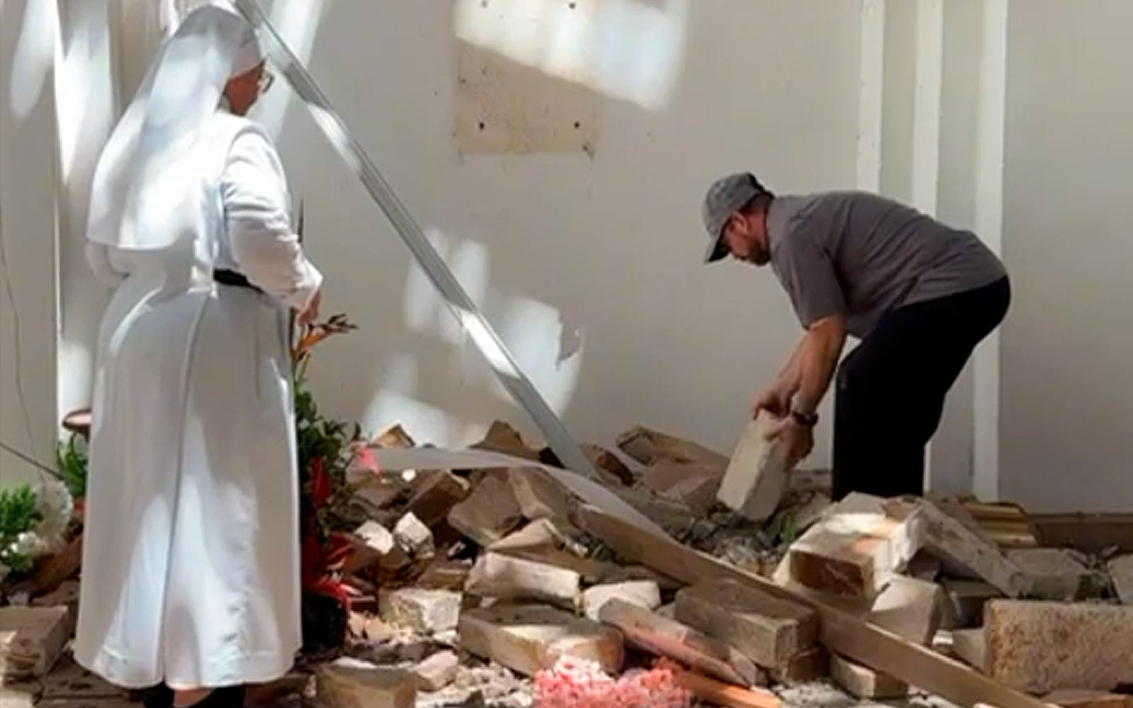 Priest and nun recover sacred hosts from earthquake rubble in Colombia – #Catholic – When the Aug. 10 earthquake hit the town of Chiquinquirá in Roldanillo, a subdistrict of the Valle del Cauca district in Colombia, a wooden tabernacle in a historic chapel was destroyed, scattering consecrated hosts across the floor and covering them with debris. Minutes later, the pastor and a nearby religious sister gathered them up to take care of them according to Church protocol.The quake severely damaged Our Lady of the Rosary chapel, which dates back to the 17th century. Inside the chapel’s tabernacle was the ciborium containing the consecrated hosts left over from the Mass celebrated the previous Saturday by Father Germán Andrés Clavijo, the pastor of St. Sebastian Parish, the parish to which the chapel belongs.Immediately after the quake, which struck at 7:34 a.m. local time, the priest entered the chapel with Sister Marcela, a member of the Community of the Blessed Sacrament. They went straight to the wall where the tabernacle had been located. Falling debris had knocked the tabernacle down from its place. “I said to her, ‘Help me look, because the consecrated hosts are there,’” the priest recounted to ACI Prensa, the Spanish-language sister service of EWTN News. “We found the ciborium, but it was completely smashed,” Clavijo said, adding that “some of the hosts were badly broken,” so they began gathering them up with great care.As they picked them up by hand, both recited the “litanies to the Blessed Sacrament, to Jesus in the Blessed Sacrament,” and placed them into a smaller ciborium. Afterward, they sprinkled water over the debris and the areas where particles of the hosts that could no longer be gathered up might have remained.Regarding the hosts that were mixed in with dirt and debris, Clavijo said: “I told her they must be placed in a container of water so that they would dissolve” and the water could later be poured by a tree or into a potted plant.No. 1377 of the Catechism of the Catholic Church teaches that “the Eucharistic presence of Christ begins at the moment of the consecration and endures as long as the Eucharistic species subsist” in the physical appearance of bread and wine.The priest from Roldanillo said it was “very sad” to see the hosts scattered on the ground, for the Eucharist “is the life of the priest; that is the life of the Church; it is our center.”However, he said he had to be “very strong, because I had to find a solution,” adding: “It wasn’t the time for lamenting; after all, the earthquake had just happened, and we were in a very unsafe spot, fearing that an aftershock or something else might cause debris to come crashing down on us.” Instagram postThe quake’s effects in RoldanilloRoldanillo was one of the areas hardest hit areas by the earthquake. Located about 90 miles from Cali and founded in 1576, many of its buildings date back to the colonial era and the early days of the republic.The day after the natural disaster, the Valle del Cauca governorʼs office reported that two people had died and 112 were injured. In addition, nearly 1,300 homes were affected, “some of which have completely collapsed,” and “60% of the hospital sustained structural damage.”Regarding the parish church, the priest said that it is has closed due to the effects of the earthquake, so Masses are being celebrated in the town square. The chapel cannot be used either, and its restoration will depend on the Colombian government as it is classified as a national heritage building.In the video he shared on the day of the earthquake, Clavijo expressed his solidarity with the residents of Roldanillo: “Amid the rubble left behind, I also wish to offer a prayer of hope and encouragement for those who have lost everything, especially those who have lost a loved one.”
 
 The Aug. 10, 2026, earthquake that hit the town of Chiquinquirá in Roldanillo, a subdistrict of the Valle del Cauca district in Colombia, severely damaged Our Lady of the Rosary chapel, which dates back to the 17th century.| Credit: Photo courtesy of Father Germán Andrés Clavijo/video screenshot
 
 The priest affirmed that, although it is not easy, “with hope and God’s hand, all of us united, will overcome this storm. As the Gospel said yesterday [Sunday, Aug. 9], sometimes we walk amid strong winds and turbulent waves, and our boat seems to be sinking, but God reaches out his hand to us. Like Peter, we all cry out: ‘Lord, save us.’”“And that is what we pray for today. To all of you, I offer my blessing and words of encouragement and hope during these times. In the name of the Father, and of the Son, and of the Holy Spirit,” he said, blessing the viewers.This story was first published by ACI Prensa, the Spanish-language sister service of EWTN News. It has been translated and adapted by EWTN News English.