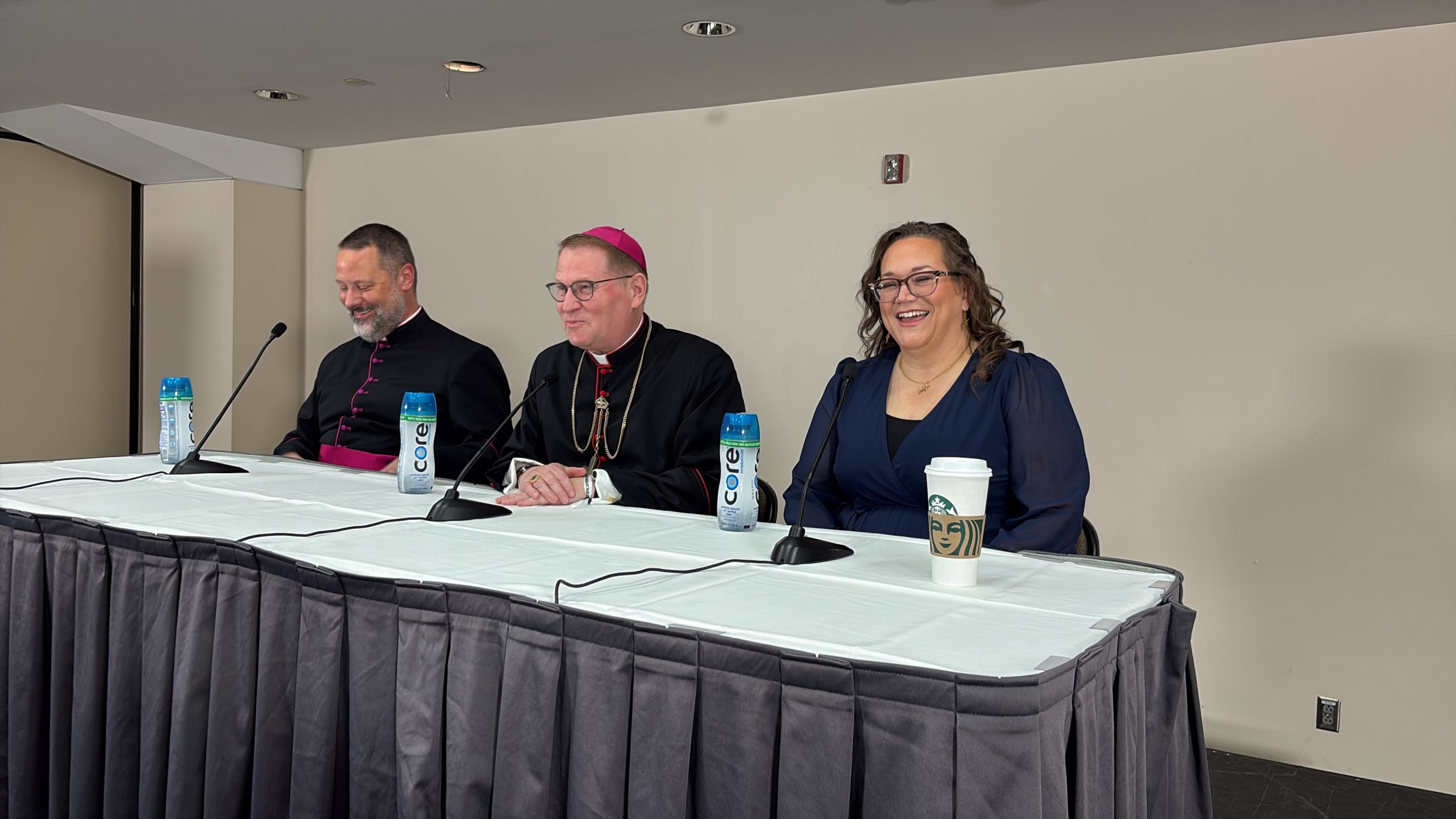 ‘A foretaste of heaven’: Sheen beatification organizers eager for Mass – #Catholic – ST. LOUIS — For Bonnie Engstrom, who witnessed her newborn child miraculously healed through the intercession of soon-to-be Blessed Archbishop Fulton Sheen, the journey to the prelate’s beatification has been an “emotional roller coaster.”The Sept. 24 Mass will be “a foretaste of heaven,” she predicted, “where we are all going to be worshipping God together and celebrating the Church as a whole, and the power of the body of Christ and every good grace that God has given us. I am so looking forward to it,” Engstrom said at a Thursday morning press conference.Engstrom spoke to the media along with Bishop Louis Tylka of the Diocese of Peoria, Illinois, and Monsignor Jason Gray, executive director of the Archbishop Fulton J. Sheen Foundation in Peoria. Gray said it is a relief, after years of technical investigations and paperwork, to see their work finally come to fruition and be able to join in the celebration of Sheen with the faithful.That said, Gray admitted he has been surprised during the process at how much attention Sheen has attracted, particularly among young people.“One question that came up early on [was]: Whoʼs going to care? All the people who knew him when his program was on are very old. But weʼve discovered young people are inspired by Sheen, because heʼs a voice of integrity that inspires people who did not know him in life, that have discovered him in the years since,” Gray said. “So itʼs just exciting to see how much enthusiasm there is,”Tylka agreed, highlighting the fact that Sheen pioneered “new media” in his day — attracting wide attention, including from non-Catholics — serving as an inspiration to those looking to do the same in 2026. He also showed how to bridge divisions in the Church and in the world because he “always spoke with the truth of the Gospel, with charity and with clarity.”“Sheenʼs message is timeless because he spoke the truth and he spoke the truth with clarity and charity. I think a lot of people in the world, especially young people, are searching for purpose and meaning and to have a voice that so convicted, he presents the truth of our faith, our belief in Jesus Christ, the truth that God loves us and that life is worth living. I think thatʼs very appealing,” Tylka said.‘Local boy’The beatification Mass Thursday afternoon will include 89 bishops, about 1,000 priests, about 850 each of seminarians and religious, and 250 deacons, along with about 50,000 total attendees, Gray said. The Mass, which can be viewed live on EWTN with coverage beginning at 2:30 p.m. ET, will be celebrated by Cardinal Luis Antonio Tagle, Pope Leo XIV’s representative.James Fulton Engstrom, the third of Bonnie and Travis’ eight children and the recipient of the confirmed miracle that led to Sheen’s beatification, will play a part in the Mass by presenting several relics of Sheen onstage. Gray and Tylka both displayed two of the relics during the press conference: one of Sheen’s zuchettos — the reddish-purple skullcap worn by archbishops — and Sheen’s pectoral cross.
 
 One of Archbishop Fulton Sheen’s zuchettos, the reddish-purple skullcap worn by archbishops, is displayed during a press conference ahead of Sheenʼs beatification on Sept. 24, 2026. | Credit: Jonah McKeown/EWTN News
 
 James Fulton, who was born in 2010, spent 61 minutes without a heartbeat while his mother prayed fervently to Sheen to help her child — whom she and her husband had already named after the famous archbishop. Almost exactly 16 years later, James is a happy and healthy teenager. The fact that James’ healing was a miracle was attested to unanimously by the medical experts, cardinals and others at the Vatican tasked with investigating it. In a later on-air interview with EWTN on Thursday, his mother said she sees a connection between Sheen’s devotion to spending an hour before the Blessed Sacrament every day and the 61 minutes her son lie lifeless.“As a laywoman, I was so impressed with how thorough the investigation was. And Travis and I felt very reassured that, wow, when the Catholic Church says something is a miracle, it is a miracle,” Engstrom commented during the press conference.When asked why she chose to call upon Sheen specifically in such a dire moment, Engstrom noted that Sheen had been a favorite of their family for years — a “local boy” with a down-to-earth Midwestern air, a “warm character” who reminded Engstrom of her own grandfather and great-grandfather. In that context, calling on Sheen during the worst hour of her and her husband’s life made complete sense, she said.Despite his highly unusual birth story, James himself is an ordinary kid, a “punk teenage boy,” Engstrom joked, who didn’t ask to be thrust into the spotlight. Nevertheless, he is also a “delightful young man” who is excited — albeit a little nervous — to play a part in the beatification Mass for the intercessor who helped save his life, Engstrom continued.“For all of our children, weʼve put all of our kids under the patronage of a saint and have really built a culture where we are celebrating feast days. We are calling on their intercession. I want all of my kids to feel like they have a squad that surrounds them, that is following them through life, praying for them, interceding, cheering them on,” she said.Gray noted that because the late Pope Francis originally announced Sheen’s beatification in July 2019, any purported miracle attributed to his intercession that has taken place since then can count toward his eventual canonization, which typically requires a second miracle to move forward. Gray said the Vatican is considering six different potential miracles involving Sheen’s intercession, including an alleged instantaneous healing from cancer and a healing of another newborn from a condition similar to James’. Pope Leo, a native of Illinois like Sheen, is well aware of the archbishop’s cause, Tylka added.Both Tylka and Gray said they have no doubt that Sheen will one day be canonized.“Americaʼs bishop, as Sheen was known, is being beatified during the 250th anniversary of our nation,” Tylka said. “And we have a pope from Chicago, a native son of Illinois, who gave the green light for this to move forward. So I think all of those things say itʼs pretty opportune … I hope that the time between now and actual canonization wonʼt be that long.”