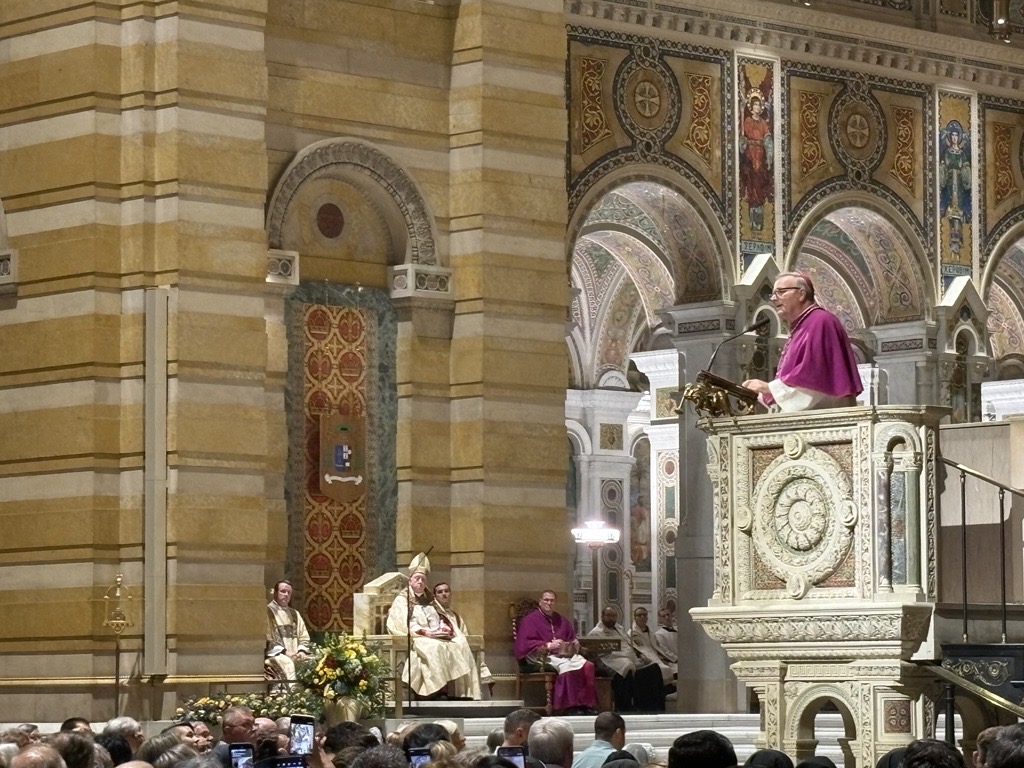‘A powerful heavenly friend and intercessor’: Bishop Barron reflects on Fulton Sheen – #Catholic – ST. LOUIS — Families with young children, religious sisters and brothers, and pilgrims who had traveled to St. Louis filled the Cathedral Basilica of St. Louis Sept. 23 for evening prayer on the eve of the beatification of Archbishop Fulton J. Sheen.More than 1,000 people gathered for the service, as the cathedral’s schola sang the psalms and canticles and Archbishop Mitchell T. Rozanski of the Archdiocese of St. Louis presided. Bishop Robert Barron of Diocese of Winona-Rochester, Minnesota, preached.Barron began by recalling Sheen’s extraordinary influence as a preacher and communicator, including the millions who watched his television programs at the height of his career.But Barron said he wanted to focus on a different question: What made Sheen “blessed, a saintly man of God”?His answer, according to Barron, was friendship with Jesus Christ.From the beginning of his own work in evangelization, Barron said, Sheen had been his “motto and inspiration.” Sheen repeatedly insisted that Christianity was not an abstract philosophy or simply a set of moral convictions but a relationship with a living person — Jesus Christ, who told his apostles that he no longer called them servants but friends.Barron found a window into that friendship in Sheen’s autobiography, “Treasure in Clay,” particularly in Sheen’s reflection on the prophet Isaiah’s encounter with God.The passage offered a template for the spiritual journey, Barron said. It begins with an encounter with the holiness of God, moves through a recognition of one’s own unworthiness and ends with a willingness to be sent on mission.The first movement, he said, is grace.“Sheen’s life was marked through and through by signs of unmerited divine love,” Barron said. That grace was closely connected to Sheen’s devotion to Mary, whom Scripture describes as “full of grace.”“Mary, as it were, haunts the spiritual life of Fulton Sheen,” Barron said.He traced that devotion from Sheen’s baptism at St. Mary Church in El Paso, Illinois, through his priestly ordination in the Cathedral of St. Mary of the Immaculate Conception in Peoria, his devotion to the rosary, and his more than 30 journeys to Lourdes. Sheen went there, Barron recalled, to visit “the woman I love.”For Sheen, Mary was the supreme example of a human being receiving the unmerited love of God.
Left to right: Sisters of Life Maria Augustine, Mariam, and Leonie Thérèse smile in front of the Cathedral Basilica of St. Louis following evening prayer Sept. 23, 2026, the vigil of the beatification of Archbishop Fulton Sheen. | Credit: Gigi Duncan/EWTN News
That understanding of love for God also shaped Sheen’s approach to the Eucharist. Barron pointed to Sheen’s lifelong commitment to the Holy Hour, when he would spend an uninterrupted hour each day in prayer before the Blessed Sacrament.Sheen saw the Holy Hour not as a task to be accomplished but as time spent in the presence of Christ. “Looking at the Eucharistic Lord for an hour transforms the heart in a mysterious way,” he wrote.Barron also recalled Sheen’s image of the person who faithfully sits before the tabernacle as “like a dog at the master’s door ready to see” where the master will send him.That preparation would lead Sheen to radio and television, where he saw new opportunities to bring the Gospel to a much wider audience. His academic formation, Barron noted, was always directed toward that apostolic purpose. Sheen wanted to bring the Catholic intellectual tradition to bear on the questions of his time while communicating it in ways ordinary people could understand.He repeatedly heard, Barron said, Christ’s command to “go out into the deep.”Sheen answered that call through decades of preaching, writing, broadcasting, and missionary travel. Yet “Treasure in Clay” also reveals the fragility of the person carrying that treasure.Sheen openly acknowledged his weaknesses, including his enjoyment of titles, prestige, and popularity. “I was popular,” Sheen wrote. “I was sought after, I was a friend of both royalty and the masses.” Then came the question: “How close was I to the cross?”For Barron, that honesty was part of Sheen’s holiness. The closer a person comes to the holiness of God, he said, the more clearly that person sees his own need for forgiveness and healing.“God is holy. I am not. Woe is me,” Barron quoted Sheen as saying.Sheen’s sufferings, including those that came from within and outside the Church, became part of that purification. As Sheen put it, “Since I would not take up the cross, the Lord would lay it on my back.”Through that process, Barron said, Sheen became more deeply conformed to Christ and more ready to be sent. Those themes were reflected in the way people at the cathedral spoke about Sheen and his continuing influence.Sister of Life Maria Augustine, who traveled from New York with other members of her community, called Sheen “a great teacher and a great evangelist.”“We look to him for his inspiration and his intercession as we go out into the world,” she said, “to proclaim the good news of human life and love.”
Cardinal Raymond Burke blesses an item outside of the Cathedral Basilica of St. Louis following vespers on Sept. 23, 2026. | Credit: Gigi Duncan/EWTN News
For Cardinal Raymond Burke, Sheen’s example has particular significance for the priesthood. Burke said Sheen inspired his own priestly vocation, and he continues to read Sheen today to deepen his “knowledge and love of the holy priesthood.”Bishop Andrew Cozzens of Crookston, Minnesota, pointed to Sheen’s deep Eucharistic devotion as the source of his evangelizing work.“To me, Fulton Sheen is a man who was so deeply in love with Jesus in the Eucharist, that he just let that shine out in everything that he does,” Cozzens told EWTN News. “And that’s what I try to do too.”
Bishop Andrew Cozzens of the Diocese of Crookston, Minnesota, meets pilgrims outside the Cathedral Basilica of St. Louis following vespers on the eve of the beatification of Archbishop Fulton Sheen on Sept. 23, 2026. | Credit: Gigi Duncan/EWTN News
Barron returned at the end of his homily to the Church’s continuing work of evangelization. The beatification, he said, does not make Sheen any greater; rather, it brings him “in a powerful way before the attention of the world.”Those seeking “fresh language” to bring the Gospel to modern culture, Barron said, are indebted to Sheen. So are those who preach the “ancient faith with a heart on fire” and those willing to use the communications technologies available to them.For them, Barron said, Sheen is “a powerful heavenly friend and intercessor.”EWTN will provide live coverage of the beatification of Archbishop Fulton Sheen on Sept. 24, with broadcast coverage beginning at 10 a.m. ET with a “Beatification Pre-Show” from The Dome at America’s Center in St. Louis, followed by the “Mass of Beatification” at 2:30 p.m. ET. Live updates will also be available through the EWTN News live blog. ‘A powerful heavenly friend and intercessor’: Bishop Barron reflects on Fulton Sheen – #Catholic – ST. LOUIS — Families with young children, religious sisters and brothers, and pilgrims who had traveled to St. Louis filled the Cathedral Basilica of St. Louis Sept. 23 for evening prayer on the eve of the beatification of Archbishop Fulton J. Sheen.More than 1,000 people gathered for the service, as the cathedral’s schola sang the psalms and canticles and Archbishop Mitchell T. Rozanski of the Archdiocese of St. Louis presided. Bishop Robert Barron of Diocese of Winona-Rochester, Minnesota, preached.Barron began by recalling Sheen’s extraordinary influence as a preacher and communicator, including the millions who watched his television programs at the height of his career.But Barron said he wanted to focus on a different question: What made Sheen “blessed, a saintly man of God”?His answer, according to Barron, was friendship with Jesus Christ.From the beginning of his own work in evangelization, Barron said, Sheen had been his “motto and inspiration.” Sheen repeatedly insisted that Christianity was not an abstract philosophy or simply a set of moral convictions but a relationship with a living person — Jesus Christ, who told his apostles that he no longer called them servants but friends.Barron found a window into that friendship in Sheen’s autobiography, “Treasure in Clay,” particularly in Sheen’s reflection on the prophet Isaiah’s encounter with God.The passage offered a template for the spiritual journey, Barron said. It begins with an encounter with the holiness of God, moves through a recognition of one’s own unworthiness and ends with a willingness to be sent on mission.The first movement, he said, is grace.“Sheen’s life was marked through and through by signs of unmerited divine love,” Barron said. That grace was closely connected to Sheen’s devotion to Mary, whom Scripture describes as “full of grace.”“Mary, as it were, haunts the spiritual life of Fulton Sheen,” Barron said.He traced that devotion from Sheen’s baptism at St. Mary Church in El Paso, Illinois, through his priestly ordination in the Cathedral of St. Mary of the Immaculate Conception in Peoria, his devotion to the rosary, and his more than 30 journeys to Lourdes. Sheen went there, Barron recalled, to visit “the woman I love.”For Sheen, Mary was the supreme example of a human being receiving the unmerited love of God.
Left to right: Sisters of Life Maria Augustine, Mariam, and Leonie Thérèse smile in front of the Cathedral Basilica of St. Louis following evening prayer Sept. 23, 2026, the vigil of the beatification of Archbishop Fulton Sheen. | Credit: Gigi Duncan/EWTN News
That understanding of love for God also shaped Sheen’s approach to the Eucharist. Barron pointed to Sheen’s lifelong commitment to the Holy Hour, when he would spend an uninterrupted hour each day in prayer before the Blessed Sacrament.Sheen saw the Holy Hour not as a task to be accomplished but as time spent in the presence of Christ. “Looking at the Eucharistic Lord for an hour transforms the heart in a mysterious way,” he wrote.Barron also recalled Sheen’s image of the person who faithfully sits before the tabernacle as “like a dog at the master’s door ready to see” where the master will send him.That preparation would lead Sheen to radio and television, where he saw new opportunities to bring the Gospel to a much wider audience. His academic formation, Barron noted, was always directed toward that apostolic purpose. Sheen wanted to bring the Catholic intellectual tradition to bear on the questions of his time while communicating it in ways ordinary people could understand.He repeatedly heard, Barron said, Christ’s command to “go out into the deep.”Sheen answered that call through decades of preaching, writing, broadcasting, and missionary travel. Yet “Treasure in Clay” also reveals the fragility of the person carrying that treasure.Sheen openly acknowledged his weaknesses, including his enjoyment of titles, prestige, and popularity. “I was popular,” Sheen wrote. “I was sought after, I was a friend of both royalty and the masses.” Then came the question: “How close was I to the cross?”For Barron, that honesty was part of Sheen’s holiness. The closer a person comes to the holiness of God, he said, the more clearly that person sees his own need for forgiveness and healing.“God is holy. I am not. Woe is me,” Barron quoted Sheen as saying.Sheen’s sufferings, including those that came from within and outside the Church, became part of that purification. As Sheen put it, “Since I would not take up the cross, the Lord would lay it on my back.”Through that process, Barron said, Sheen became more deeply conformed to Christ and more ready to be sent. Those themes were reflected in the way people at the cathedral spoke about Sheen and his continuing influence.Sister of Life Maria Augustine, who traveled from New York with other members of her community, called Sheen “a great teacher and a great evangelist.”“We look to him for his inspiration and his intercession as we go out into the world,” she said, “to proclaim the good news of human life and love.”
Cardinal Raymond Burke blesses an item outside of the Cathedral Basilica of St. Louis following vespers on Sept. 23, 2026. | Credit: Gigi Duncan/EWTN News
For Cardinal Raymond Burke, Sheen’s example has particular significance for the priesthood. Burke said Sheen inspired his own priestly vocation, and he continues to read Sheen today to deepen his “knowledge and love of the holy priesthood.”Bishop Andrew Cozzens of Crookston, Minnesota, pointed to Sheen’s deep Eucharistic devotion as the source of his evangelizing work.“To me, Fulton Sheen is a man who was so deeply in love with Jesus in the Eucharist, that he just let that shine out in everything that he does,” Cozzens told EWTN News. “And that’s what I try to do too.”
Bishop Andrew Cozzens of the Diocese of Crookston, Minnesota, meets pilgrims outside the Cathedral Basilica of St. Louis following vespers on the eve of the beatification of Archbishop Fulton Sheen on Sept. 23, 2026. | Credit: Gigi Duncan/EWTN News
Barron returned at the end of his homily to the Church’s continuing work of evangelization. The beatification, he said, does not make Sheen any greater; rather, it brings him “in a powerful way before the attention of the world.”Those seeking “fresh language” to bring the Gospel to modern culture, Barron said, are indebted to Sheen. So are those who preach the “ancient faith with a heart on fire” and those willing to use the communications technologies available to them.For them, Barron said, Sheen is “a powerful heavenly friend and intercessor.”EWTN will provide live coverage of the beatification of Archbishop Fulton Sheen on Sept. 24, with broadcast coverage beginning at 10 a.m. ET with a “Beatification Pre-Show” from The Dome at America’s Center in St. Louis, followed by the “Mass of Beatification” at 2:30 p.m. ET. Live updates will also be available through the EWTN News live blog.