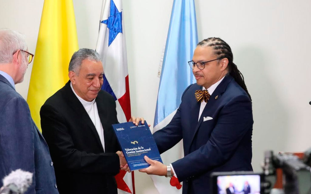 Archbishop of Panama asks victims for forgiveness: ‘We cannot remain silent in the face of abuse’ #Catholic The archbishop of Panama, José Domingo Ulloa Mendieta, stated that “we cannot remain silent in the face of abuse” during his presentation of the report “Assessment of Institutional Responses (AIR) in cases of sexual abuse of minors and vulnerable persons” within the Archdiocese of Panama between 2001 and 2025.The report by the Transparency Commission (TC), a pilot project and the first from an interdisciplinary group of independent experts on addressing and preventing abuse within ecclesial settings, was presented on Sept. 22 at the Santa María La Antigua University auditorium in Panama City.Speaking during the presentation, Ulloa emphasized: “It has already been said here, and we know it: Our Panamanian culture often prefers to remain silent, but in the face of abuse, we cannot remain silent.”“We want to listen; we want to take every complaint seriously, with respect, and confidentiality, protecting the individuals involved and acting in accordance with established procedures,” he added.The prelate explained that the archdiocese he leads “remains committed to reporting relevant allegations to the competent civil authorities in accordance with current legislation” and acknowledged the need to ask what can be done better to move forward in the prevention of abuse.“A culture of protection is not built solely through written rules; it is built when every priest, religious, pastoral worker, collaborator, and member of our communities understands that protecting minors and vulnerable persons is an ongoing, shared responsibility,” the archbishop emphasized.Asking forgiveness of the victimsThe prelate also addressed “in a special way victims and survivors. We are deeply pained by the suffering you have endured.”“It pains us to know that those who should have found a place of welcome, care, and trust within the Church experienced situations that caused them such deep wounds,” he continued.Ulloa emphasized that “wherever members of our Church caused harm, and wherever our institutional response fell short of what the victims needed and had a right to expect, we ask for forgiveness in the name of the Church.”The archbishop also noted that “over this 25-year period, and I wish to highlight this especially for the media, more than 18 priests have been removed from priestly ministry due to situations involving the Sixth Commandment, offenses against property, or other issues they have experienced.”The Transparency CommissionAccording to its website, the Transparency Commission (TC) was established to conduct comprehensive investigations “in a holistic, professional, independent, and rigorous manner regarding cases of abuse of minors and vulnerable persons within the Church.” It is funded by the University of Notre Dame Law School in Indiana and Villanueva University in Madrid.“This group of experts focuses its work on places where crises related to ecclesial abuse have not yet occurred or have not come to light,” notes the TC website.
Presentation of the report to the archbishop of Panama, José Domingo Ulloa. | Credit: Archdiocese of Panama
The report indicates that in cases of sexual abuse, the AIR “must place victims at the center of the analysis, since the way the institution protects their rights, addresses their needs, and fosters their reparation constitutes the primary criterion for evaluating the quality of the response provided.”The Transparency Commission is composed of 17 individuals coordinated by Father Jordi Pujol, a lawyer who holds a doctorate in moral theology and is also a professor of law and communication ethics at the Pontifical University of the Holy Cross in Rome.Its members include Father Thomas Berg, a professor and researcher at the McGrath Institute for Church Life at the University of Notre Dame; Yago de la Cierva, a professor of preventive and crisis communication at the Pontifical University of the Holy Cross; and Irma Patricia Espinosa, a psychiatrist, member of the National Council for the Protection of Minors of the Mexican Bishops’ Conference, academic director and founding partner of the Center for Interdisciplinary Research and Training for the Protection of Minors (CEPROME) Latin America, and a member of the Pontifical Commission for the Protection of Minors since 2022.Also serving on the Transparency Commission are María Inés Franck, professor of canon law at the Pontifical Catholic University of Argentina and a member of the Pastoral Council for the Protection of Minors of the Argentine Bishops’ Conference; Monsignor John Paul Kimes, professor of canon law at the University of Notre Dame Law School; and Father Daniel Portillo, dean of the psychology department at Lumen Gentium Catholic University in Mexico. He is the director and a founding member of CEPROME Latin America.The Panama ReportThe request for the report goes back to October 2025, when the archbishop of Panama requested an assessment of institutional response from the TC “on his own initiative, without a court order or a request from the Holy See.”The commission stated that it accepted the assignment subject to three conditions: full access to information, total independence in the investigation, and a commitment to publish the findings. The archdiocese did not intervene in the compilation of the report and only saw it days before its presentation.The TC states that it operated with financial independence: Its members received no remuneration from the archdiocese, and costs were covered by Notre Dame Law School and the Villanueva University Foundation. The archdiocese only covered transportation and accommodation and provided workspace.The commission reported that, during the period under review, the archdiocese received 37 complaints of which it analyzed 24, while the remaining 13 were excluded from the analysis “because they referred to events that occurred outside the archdioceseʼs territory or the time frame examined, or because they did not involve abuse against minors or vulnerable persons.”The report reveals that case management improved thanks to two initiatives by the archdiocese: the approval of guidelines in 2015 and the creation in 2024 of the Pastoral Care and Prevention Office and the Listening Office.The report, currently available only in Spanish, identifies five areas requiring improvement: listening to and accompanying victims; recordkeeping; prevention; justice for victims; and reparation.“Making reparation requires acknowledging the harm, accepting personal and institutional responsibility, and addressing the physical, psychological, moral, spiritual, and social needs of each victim,” the commission emphasizes.The pilot projectIn a FAQ section about the report, the TC explains that this work is a pilot project because “it is the first time that a comprehensive methodology has been applied that can be replicated in other dioceses or ecclesial organizations.”“This first project has allowed us to test a methodology and a work system, based on professional listening, research in archives, conducting interviews with various audiences of interest, and media analysis and the sociocultural context of the country,” it adds.The Transparency Commission further specifies that the working methodology aims to “place victims at the center, protecting their rights, and guarantee due process for the accused,” applying a clear standard of prudence to avoid “revictimizing a victim or blaming an innocent person.”The Transparency Commission also noted that “the Vatican has been kept informed of the workʼs progress at all times; both the Pontifical Commission for the Protection of Minors and the Pontifical Commission for Latin America are aware of the TC’s work. Furthermore, some members of the commission work or have worked with both the Pontifical Commission for the Protection of Minors and the Dicastery for the Doctrine of the Faith.”The TC concludes by noting that anyone who has suffered abuse within the Church may, at any time, turn to the Archdiocese of Panama’s Listening Office and file a report with the public prosecutorʼs office.This story was first published by ACI Prensa, the Spanish-language sister service of EWTN News. It has been translated and adapted by EWTN News English. Archbishop of Panama asks victims for forgiveness: ‘We cannot remain silent in the face of abuse’ #Catholic The archbishop of Panama, José Domingo Ulloa Mendieta, stated that “we cannot remain silent in the face of abuse” during his presentation of the report “Assessment of Institutional Responses (AIR) in cases of sexual abuse of minors and vulnerable persons” within the Archdiocese of Panama between 2001 and 2025.The report by the Transparency Commission (TC), a pilot project and the first from an interdisciplinary group of independent experts on addressing and preventing abuse within ecclesial settings, was presented on Sept. 22 at the Santa María La Antigua University auditorium in Panama City.Speaking during the presentation, Ulloa emphasized: “It has already been said here, and we know it: Our Panamanian culture often prefers to remain silent, but in the face of abuse, we cannot remain silent.”“We want to listen; we want to take every complaint seriously, with respect, and confidentiality, protecting the individuals involved and acting in accordance with established procedures,” he added.The prelate explained that the archdiocese he leads “remains committed to reporting relevant allegations to the competent civil authorities in accordance with current legislation” and acknowledged the need to ask what can be done better to move forward in the prevention of abuse.“A culture of protection is not built solely through written rules; it is built when every priest, religious, pastoral worker, collaborator, and member of our communities understands that protecting minors and vulnerable persons is an ongoing, shared responsibility,” the archbishop emphasized.Asking forgiveness of the victimsThe prelate also addressed “in a special way victims and survivors. We are deeply pained by the suffering you have endured.”“It pains us to know that those who should have found a place of welcome, care, and trust within the Church experienced situations that caused them such deep wounds,” he continued.Ulloa emphasized that “wherever members of our Church caused harm, and wherever our institutional response fell short of what the victims needed and had a right to expect, we ask for forgiveness in the name of the Church.”The archbishop also noted that “over this 25-year period, and I wish to highlight this especially for the media, more than 18 priests have been removed from priestly ministry due to situations involving the Sixth Commandment, offenses against property, or other issues they have experienced.”The Transparency CommissionAccording to its website, the Transparency Commission (TC) was established to conduct comprehensive investigations “in a holistic, professional, independent, and rigorous manner regarding cases of abuse of minors and vulnerable persons within the Church.” It is funded by the University of Notre Dame Law School in Indiana and Villanueva University in Madrid.“This group of experts focuses its work on places where crises related to ecclesial abuse have not yet occurred or have not come to light,” notes the TC website.
Presentation of the report to the archbishop of Panama, José Domingo Ulloa. | Credit: Archdiocese of Panama
The report indicates that in cases of sexual abuse, the AIR “must place victims at the center of the analysis, since the way the institution protects their rights, addresses their needs, and fosters their reparation constitutes the primary criterion for evaluating the quality of the response provided.”The Transparency Commission is composed of 17 individuals coordinated by Father Jordi Pujol, a lawyer who holds a doctorate in moral theology and is also a professor of law and communication ethics at the Pontifical University of the Holy Cross in Rome.Its members include Father Thomas Berg, a professor and researcher at the McGrath Institute for Church Life at the University of Notre Dame; Yago de la Cierva, a professor of preventive and crisis communication at the Pontifical University of the Holy Cross; and Irma Patricia Espinosa, a psychiatrist, member of the National Council for the Protection of Minors of the Mexican Bishops’ Conference, academic director and founding partner of the Center for Interdisciplinary Research and Training for the Protection of Minors (CEPROME) Latin America, and a member of the Pontifical Commission for the Protection of Minors since 2022.Also serving on the Transparency Commission are María Inés Franck, professor of canon law at the Pontifical Catholic University of Argentina and a member of the Pastoral Council for the Protection of Minors of the Argentine Bishops’ Conference; Monsignor John Paul Kimes, professor of canon law at the University of Notre Dame Law School; and Father Daniel Portillo, dean of the psychology department at Lumen Gentium Catholic University in Mexico. He is the director and a founding member of CEPROME Latin America.The Panama ReportThe request for the report goes back to October 2025, when the archbishop of Panama requested an assessment of institutional response from the TC “on his own initiative, without a court order or a request from the Holy See.”The commission stated that it accepted the assignment subject to three conditions: full access to information, total independence in the investigation, and a commitment to publish the findings. The archdiocese did not intervene in the compilation of the report and only saw it days before its presentation.The TC states that it operated with financial independence: Its members received no remuneration from the archdiocese, and costs were covered by Notre Dame Law School and the Villanueva University Foundation. The archdiocese only covered transportation and accommodation and provided workspace.The commission reported that, during the period under review, the archdiocese received 37 complaints of which it analyzed 24, while the remaining 13 were excluded from the analysis “because they referred to events that occurred outside the archdioceseʼs territory or the time frame examined, or because they did not involve abuse against minors or vulnerable persons.”The report reveals that case management improved thanks to two initiatives by the archdiocese: the approval of guidelines in 2015 and the creation in 2024 of the Pastoral Care and Prevention Office and the Listening Office.The report, currently available only in Spanish, identifies five areas requiring improvement: listening to and accompanying victims; recordkeeping; prevention; justice for victims; and reparation.“Making reparation requires acknowledging the harm, accepting personal and institutional responsibility, and addressing the physical, psychological, moral, spiritual, and social needs of each victim,” the commission emphasizes.The pilot projectIn a FAQ section about the report, the TC explains that this work is a pilot project because “it is the first time that a comprehensive methodology has been applied that can be replicated in other dioceses or ecclesial organizations.”“This first project has allowed us to test a methodology and a work system, based on professional listening, research in archives, conducting interviews with various audiences of interest, and media analysis and the sociocultural context of the country,” it adds.The Transparency Commission further specifies that the working methodology aims to “place victims at the center, protecting their rights, and guarantee due process for the accused,” applying a clear standard of prudence to avoid “revictimizing a victim or blaming an innocent person.”The Transparency Commission also noted that “the Vatican has been kept informed of the workʼs progress at all times; both the Pontifical Commission for the Protection of Minors and the Pontifical Commission for Latin America are aware of the TC’s work. Furthermore, some members of the commission work or have worked with both the Pontifical Commission for the Protection of Minors and the Dicastery for the Doctrine of the Faith.”The TC concludes by noting that anyone who has suffered abuse within the Church may, at any time, turn to the Archdiocese of Panama’s Listening Office and file a report with the public prosecutorʼs office.This story was first published by ACI Prensa, the Spanish-language sister service of EWTN News. It has been translated and adapted by EWTN News English.