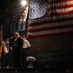 ‘I remember like it was yesterday’: Catholics describe ministering in aftermath of 9/11 #Catholic – (OSV News) — On Sept. 11, 2001 — the date of the worst terrorist attack in American history, when four hijacked jets became deadly weapons — there was no shortage of heroic first responders who confronted danger instead of avoiding it.
Many Catholic clergy and religious ministered among them — including priests, friars and sisters. Some of their stories are perhaps less well known — but the help and healing they also brought to those who experienced the devastating losses of 9/11 are worth remembrance as the 25th anniversary approaches.
“I remember like it was yesterday,” Father Brian Jordan told OSV News.
A Franciscan friar of his order’s Province of Our Lady of Guadalupe, the priest is the current pastor of the Church of St. Francis of Assisi on West 31st Street in New York City.
That morning, Father Jordan was at New York Presbyterian Hospital. Hearing of the strike, he returned to the Franciscan friary on 31st Street — attached to St. Francis of Assisi Parish — where he lived, determined to go to the disaster site.
Uncertain what he might find — but expecting both victims and perpetrators — he retrieved holy water and a pair of brass knuckles. “I said, ‘I’ll bless them with one hand, and just in case there’s any bad guys, I’ll bless them with the other hand.”

Click here to subscribe to our weekly newsletter.

Before he left, another friar had devastating news: Their fellow Franciscan, Father Mychal Judge, was dead. Still, Father Jordan knew what Father Judge would want him to do — go help.
After stopping at Manhattan’s St. Vincent’s Hospital — the only patients were those being treated for dust inhalation after the Twin Towers collapsed — Father Jordan headed to ground zero, encountering a police captain he knew.
“He gave me a mask; he gave me a pair of gloves. He said, ‘Father, put the mask on, put on the gloves and go to work.’ And so I went up and down for a couple blocks, and there were bodies and body parts. I just blessed them all.”
On Sept. 16, Father Jordan said his first Mass at ground zero; he would continue to have Mass there for nearly 10 months.
Then on Sept. 23, there was a surprise.
“A big burly construction worker from Local 731 comes up to me and says, ‘Hey, Father, you want to see God’s house?’”
“So we go into the ruins of 6 World Trade Center,” recalled Father Jordan. “I had like 25 fighters next to me, and the construction worker says, ‘What do you see there, Father, right in the middle?’ I said, ‘I can’t believe this … I see a cross.’”
Two intersecting steel beams had been sheared into a crucifix, as 6 WTC was struck by debris from the collapse of the North Tower.
The stunning artifact became known as the “Cross at Ground Zero” and eventually became part of the 9/11 Memorial & Museum collection.
It was excavated, placed on a concrete abutment, and blessed. On Oct. 7, a Mass was celebrated near it, at the corner of Vesey and West streets.
“It gave a boost of energy to people at the time,” explained Father Jordan, who wrote his own memoir — “The Ground Zero Cross” (Xlibris) — and was given the distinction of being its unofficial guardian.
On 9/11, Sister Margaret O’ Brien, a Sister of Charity working in the Sisters of Charity Health Care System, was in her office at the Bayley Seton Hospital on Staten Island, briefing a colleague just returned from vacation.
“Her secretary came in and said, ‘I just got a call. A plane went into the World Trade Center,’” Sister Margaret remembered. “We went down the hall to a window we could see from, and we realized, this is going to be bad.”
The sisters quickly prepared to go to St. Vincent’s Hospital “to set up the emergency and trauma response,” explained Sister Margaret. “And the doctors were there, the stretchers were there, all waiting at the entrance — but after a short while, nobody came.”
Sister Margaret worked the hotline in the sisters’ hospital command center, taking calls from people searching for loved ones.
“The telephone was really hard,” she reflected. “Because people would give you a name and you’d check your list, and you didn’t have them. … It was very, very emotional the whole time — and for the first couple of days, the phone just kept ringing.”
Nonetheless, she found a reason to be thankful.
“I remember being so grateful I had something to be part of, to help,” said Sister Margaret, now assistant to the president of the Sisters of Charity New York.
Trauma was a persistent feature of the sisters’ shifts — especially for one colleague who assisted first responders sent for care from recovery work at ground zero.
“Sometimes people would talk, but most of the time they just couldn’t,” Sister O’Brien explained. Her colleague “remembered one person — he was very quiet — and then he said, ‘I can take the arms and the legs. But when I turned over a stone and saw a face, just a head, flattened into the ground.’”
“He lost it,” said Sister O’Brien.
Father Stephen McGraw — at the time a priest in the Diocese of Arlington, Virginia, just outside of Washington — also saw unspeakable sights.
On the morning of 9/11, he had just concluded a school Mass — and was on his way to Arlington National Cemetery for a burial when he missed the appropriate exit.
“I remember about 9:35, I’m just sitting in this traffic, right in front of the Pentagon.”
He was distressed that he would now almost certainly be late for the burial.
“And then without warning, the plane came roaring right over the tops of our cars — very, very low,” Father McGraw said. “I can’t say which of my senses was most impacted — there was the vibration and roar of the plane, and a light pole was clipped and fell over on a taxi driver’s car just a few cars away.”
Looking to his right, he watched as American Airlines Flight 77 plowed into the Pentagon.
“I saw it crashing, disappearing, with a huge fireball billowing out from the building in the moment after the crash.”
Because his radio wasn’t on to hear what was happening in New York City, “I just assumed it was a terrible, tragic accident.”
Commuters came to a frozen stop, and Father McGraw leapt from his car — stole, anointing oils and prayer book in hand — vaulting the highway guardrail to the lawn of the Pentagon to reach the victims.
“Basically, my message to them was, ‘Jesus is with you.’ That’s what I kept saying to the several victims I attended,” said Father McGraw.
One victim who identified himself as Catholic — Juan Cruz, the civilian accounting division manager in the Office of the Administrative Assistant for the Secretary of the Army — was given the sacraments.
Another — Antoinette Sherman, an Army budget analyst, who later died — lay face down on the grass, severely burned on her back, a single shoe on one foot. Father McGraw gently removed it at her request.
“Then she just said, to perhaps whomever could hear her, ‘Tell my mother and father that I love them.’ And so I assured her that I would.”
Father McGraw — now a missionary priest and church pastor in the Diocese of Arlington’s Bánica Mission in the Dominican Republic — doesn’t think his unplanned detour was a coincidence.
“I had a strong sense of divine providence,” he told OSV News. “I was meant to be there.”
The attacks killed 2,977 people and injured thousands more: 2,753 people died in the Twin Towers collapse, brought down by two hijacked commercial airliners; 184 people died when a third hijacked airliner flew into the Pentagon; and 40 people died in Shanksville, Pennsylvania, when passengers and crew fought back against hijackers on a fourth airliner, forcing it to crash in a field near Shanksville. Officials believe the fourth plane was headed for the U.S. Capitol or the White House.
The 25th anniversary of 9/11 will not only be a time of solemn remembrance — it also leaves some longing for the national unity Americans once demonstrated.
“We saw evil at its worst,” declared Father Jordan. “But we also saw goodness at its best. New York City came together. The country came together. The world came together.”
Kimberley Heatherington is an OSV News correspondent. She writes from Virginia.
&nbsp;