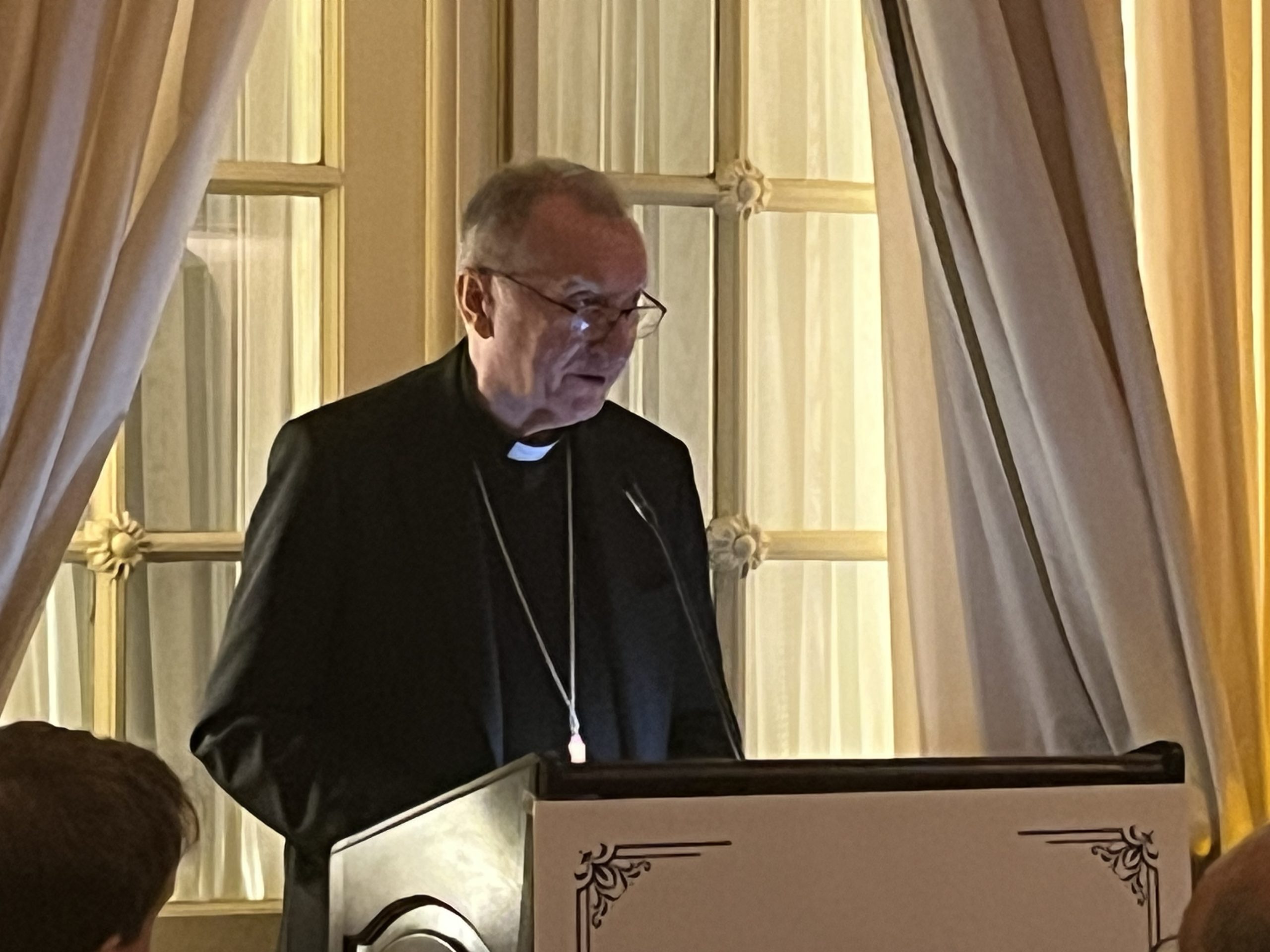 Vatican secretary of state says world’s fragmentation starts with forgetting what a human person is #Catholic NEW YORK — The root of today’s fragmented world is not technology, excess freedom, or diversity but the loss of a common understanding of who the human person is, Vatican Secretary of State Cardinal Pietro Parolin said at a New York dinner that took place during the United Nations General Assembly’s High-level Week.Parolin spoke Sept. 25 as an honoree of CAPP-USA, the U.S. arm of the Fondazione Centesimus Annus Pro Pontifice, a Vatican foundation that promotes Catholic social teaching and was established by St. John Paul II in 1993.Among those present at the event were the U.S. Ambassador to the United Nations (U.N.) Mike Waltz, Knights of Columbus Supreme Knight Patrick Kelly, and the Holy See’s permanent observer to the U.N., Archbishop Christophe-Zakhia El-Kassis, who delivered the evening’s benediction.Parolin said: “In the light of the Gospel, each generation must read the signs of its own times.”Citing Pope Leo XIV’s encyclical Magnifica Humanitas, Parolin said modern technology is not humanity’s enemy but that dignity belongs to people, not systems or algorithms. He also recalled Rerum Novarum, the encyclical Pope Leo XIII penned in 1891 as the Church’s response to the industrial revolution and which laid the foundation for Catholic social teaching.“In a world that builds towers, build places of encounter,” Parolin challenged his listeners. “In a world connected online and disconnected offline, be people of presence. In a world asking whether we can remain human, answer with the witness of your lives.”He told attendees the foundation matters because its members are meant to be “bridge builders between the encyclicals … and the decisions made in daily life.”Fragmentation and lonelinessParolin said people “are more connected than any generation in history, and yet many of us are lonelier than ever.” Exchanging information instantly but struggling to encounter one another as human beings has led to fragmentation, he said, and families, communities, and nations are “divided into camps that no longer even speak the same language.”He noted Pope Leo’s description of this moment in the opening lines of Magnifica Humanitas, saying: “We can either construct a new tower of Babel or build the city in which God and humanity dwell together.”‘A fragmented world is a searching world’Regarding the spiritual hunger many modern people are feeling, he said restlessness, especially among the young, is evidence that our hearts are made for God and cannot rest until we rest in him, citing St. Augustine.“A fragmented world is also a searching world,” he noted.“The human person is not self-made, but receives; he is a being created for relationship,” he said. “Leo expressed the hope that the world will come to recognize the human heart is the place where God desires to dwell.”The Church’s social doctrine is “itself an expression of the spiritual life,” Parolin said, and results in a faith that becomes real “concern for the worker, the family, the poor, and the seeking of the common good.”Freedom and pluralism not to blame, Parolin saysOn freedom and pluralism, he rejected blaming “too much freedom” or “too many voices.” The Church defends “freedom as a gift inseparable from human dignity,” he said, noting the Second Vatican Council’s teaching on “religious freedom as a right found in the very nature of the human person.” But, he said, “freedom detached from truth and responsibility for others turns against itself.” Freedom, in the Christian vision, “is not the capacity to choose anything whatsoever. It is the capacity to choose the good.”Authentic pluralism, he said, rests on dignity, the common good, solidarity, and subsidiarity. “We should respect the family, communities, and institutions through which people flourish,” he urged.The next day, Sept. 26, Parolin addressed the opening of the 81st U.N. General Assembly, whose theme is “Restoring Trust, Managing Transformation: A United Nations That Delivers for All.”