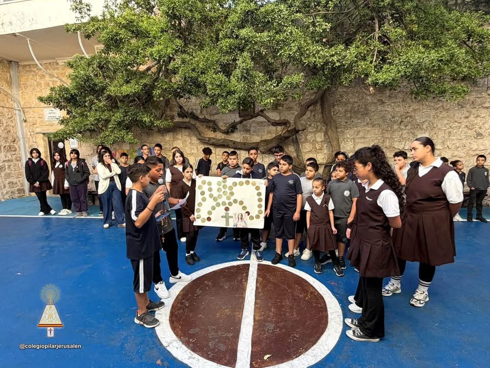 Across the Middle East, children answer Pope Leo’s call to pray the rosary for peace – #Catholic – In a Middle East scarred by war, children in Lebanon, Palestine, and Syria gathered in churches and schoolyards this month to answer Pope Leo XIV’s call to pray the rosary for peace, joining more than a million young people worldwide.
Children in Lebanon pray the rosary for peace. | Credit: Suzie El Hage
Their prayers were part of “One Million Children Praying the Rosary,” organized by the pontifical charity Aid to the Church in Need (ACN), and took place Oct. 1–7. This year’s campaign drew particular inspiration from Our Lady of Fátima’s promise: “In the end, my Immaculate Heart will triumph.” LebanonAt least 261 children have been killed and 1,056 injured in Israeli attacks on Lebanon since March 2, according to figures published by UNICEF. In March, the agency reported that an average of at least 19,000 children were being displaced each day.Against this backdrop, in the Maronite Diocese of Antelias, more than 1,300 students gathered around Bishop Antoine Bou Najem to pray. “We are praying today for children living in fear, for those who have no home, and for those enduring war, hunger, and sorrow,” Bou Najem said.
Students from schools in the Maronite Diocese of Antelias pray the rosary for peace. | Credit: Photo courtesy of the Maronite Diocese of Antelias
PalestineIn Palestine, the prayer for peace took place against the backdrop of the devastation and displacement caused by the war in Gaza, whose effects continue to weigh heavily on children and families there.In Jerusalem, Our Lady of Pilar College, also known as the Spanish School, shared photographs of its students gathered in the school courtyard to pray for peace.Located in Jerusalem’s Old City and run by the Missionary Daughters of Calvary, the school serves underprivileged students belonging to the poorest families in and around East Jerusalem.
Children gather before the altar in Homs, Syria. | Credit: Photo courtesy of the Syriac Catholic Archeparchy of Homs, Hama, and Nabk
SyriaIn Syria, children and families gathered at Holy Spirit Cathedral in Homs, a city scarred by years of war, to join the same international initiative.“From Homs, a city that has known the pain of war and longs for peace, the children’s prayers rose with a simple yet profound hope,” the Syriac Catholic Archdiocese of Homs, Hama, and Nabk wrote in its post. “Queen of Peace, pray for us … and bring the world together in love and unity.”This story was first published by ACI MENA, the Arabic-language sister service of EWTN News, and has been translated for and adapted by EWTN News English. Across the Middle East, children answer Pope Leo’s call to pray the rosary for peace – #Catholic – In a Middle East scarred by war, children in Lebanon, Palestine, and Syria gathered in churches and schoolyards this month to answer Pope Leo XIV’s call to pray the rosary for peace, joining more than a million young people worldwide.
Children in Lebanon pray the rosary for peace. | Credit: Suzie El Hage
Their prayers were part of “One Million Children Praying the Rosary,” organized by the pontifical charity Aid to the Church in Need (ACN), and took place Oct. 1–7. This year’s campaign drew particular inspiration from Our Lady of Fátima’s promise: “In the end, my Immaculate Heart will triumph.” LebanonAt least 261 children have been killed and 1,056 injured in Israeli attacks on Lebanon since March 2, according to figures published by UNICEF. In March, the agency reported that an average of at least 19,000 children were being displaced each day.Against this backdrop, in the Maronite Diocese of Antelias, more than 1,300 students gathered around Bishop Antoine Bou Najem to pray. “We are praying today for children living in fear, for those who have no home, and for those enduring war, hunger, and sorrow,” Bou Najem said.
Students from schools in the Maronite Diocese of Antelias pray the rosary for peace. | Credit: Photo courtesy of the Maronite Diocese of Antelias
PalestineIn Palestine, the prayer for peace took place against the backdrop of the devastation and displacement caused by the war in Gaza, whose effects continue to weigh heavily on children and families there.In Jerusalem, Our Lady of Pilar College, also known as the Spanish School, shared photographs of its students gathered in the school courtyard to pray for peace.Located in Jerusalem’s Old City and run by the Missionary Daughters of Calvary, the school serves underprivileged students belonging to the poorest families in and around East Jerusalem.
Children gather before the altar in Homs, Syria. | Credit: Photo courtesy of the Syriac Catholic Archeparchy of Homs, Hama, and Nabk
SyriaIn Syria, children and families gathered at Holy Spirit Cathedral in Homs, a city scarred by years of war, to join the same international initiative.“From Homs, a city that has known the pain of war and longs for peace, the children’s prayers rose with a simple yet profound hope,” the Syriac Catholic Archdiocese of Homs, Hama, and Nabk wrote in its post. “Queen of Peace, pray for us … and bring the world together in love and unity.”This story was first published by ACI MENA, the Arabic-language sister service of EWTN News, and has been translated for and adapted by EWTN News English.