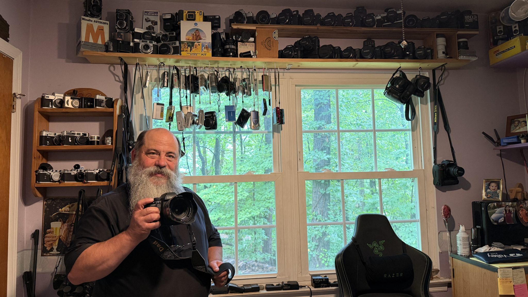 Beyond The Beacon podcast 119 – The Good News Workshop: Creating better photos with Joe Gigli #Catholic – 

How can we all create better photos? This week we get to know Joe Gigli, the gifted, long-time photographer for The Beacon and the Diocese of Paterson. Gigli shares how he got into photography, offers insight into how he thinks about creating images, and shares a few tips and tricks.
Gigli’s interview kicks off a new podcast segment titled The Good News Workshop. This intermittent segment will feature interviews with experts in different areas of communications, so we can be inspired and educated to be the best communicators and storytellers we can be as we spread the Good News of our faith in our parishes, schools, and throughout the diocese.
Bishop Kevin J. Sweeney shares his perspective on being photographed, how an image can bring people together, and discusses the power of a beautiful photograph. Co-hosted by Diocesan Communications Director Jai Agnish.
Listen or watch the episode here, or on any major podcast platform, or watch it on Bishop Sweeney’s YouTube channel.

Click here to subscribe to our weekly newsletter.

Beacon photographer Joe Gigli poses for a photograph in his home. (By Jai Agnish)