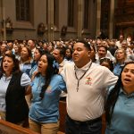 Emaús Retreat at cathedral fosters deeper life of evangelization #Catholic – Linked arm-in-arm, hand-in-hand in sung prayer, believers filled the Cathedral of St. John the Baptist as alumni of a retreat experience that has connected thousands across the Paterson Diocese and throughout New Jersey.
Pilgrims who have experienced the powerful Emaús retreat celebrated Christ’s love at a Spanish-language Mass with Bishop Kevin J. Sweeney on Sept. 25 at the cathedral.
Each of them has participated in the three-day, mainly Spanish-language experience, in which Deacon German Vargas from the cathedral has played a major part in infusing the life of faith in the diocese. He calls the “siblinghood” of Emaús a community of brothers and sisters who, after the retreat, encounter the presence, grace, love, and mercy of Christ and make the Catholic faith the center of their lives.

Click here to subscribe to our weekly newsletter.

“The bishop affirmed that the movement of the Holy Spirit has gifted us the Emaús fellowship,” Deacon Vargas shared. “The bishop emphasized the need not to be afraid and to keep walking together, like the disciples of Emmaus, strengthened by the Word of God,” he said.
The retreat program has touched thousands of New Jerseyans. Its title comes from the story of the road to Emmaus as shared in Luke. In it, Christ draws near to two people taking that road without identifying himself until he breaks bread with them in a Eucharistic expression, following the pattern of the Last Supper.
“Were not our hearts burning [within us] while he spoke to us on the way and opened the scriptures to us?” the two men say about Jesus.
Emaús, a retreat program that began at a parish in 1978 at St. Louis Parish in Miami, came to St. Mary Help of Christians in Paterson, N.J., in 2017 and has spread to 10 parishes in the diocese.
“The idea was to make a retreat for people who didn’t have the chance to go to other retreats,” said Father Duberney Villamizar, pastor at St. Margaret of Scotland Parish in Morristown, N.J., who also helps facilitate Emaús.
Father Villamizar added, “There are some retreats that require some background for the people — a discernment retreat for those thinking about vocations or retreats for couples, married couples. There were other requirements at the time this Emmaus retreat started in Florida. The parish priest wanted to have a retreat for anybody, those who are in the pews, those who are just arriving in the church.”
Through Emaús, men and women hold separate retreats that become deeply personal encounters with the Lord.
“It grew organically here at the cathedral,” said Msgr. Geno Sylva, the rector of St. John’s and diocesan vicar for special projects. “After the retreat, I started seeing not only that the lives of people who went on the retreat converted and changed, but they became so faithful, not only with being here [on] Sunday, but getting involved in so many other areas of the cathedral’s life. It’s part of my vision for evangelization here at the cathedral,” he said.
Msgr. Sylva credits Deacon Vargas and Father Villamizar with helping expand the retreat, which has become a key outreach tool, inviting people into the faith who have not had that deeper encounter with Christ.
“I have a St. John Paul II, Pope Francis, and Benedict XIV [approach] to New Evangelization. It has to be about going beyond the walls to inviting people to a larger communion and to Sunday Mass,” Msgr. Sylva said.
That invitation often comes from Emaús alums who also help make the retreat happen.
“It started forming what we call now the brotherhoods and the sisterhoods in the different parishes,” Father Villamizar said. “Those who leave the retreat already are the ones who prepare a new retreat and invite new people,” he said.
Those alumni also create regular follow-up opportunities for others who have gone on the retreat to continue the spiritual growth in community with others who know the power of the experience.
“They meet biweekly after the retreat,” Msgr. Sylva said, “and you have to make the retreat to be at those meetings because there’s a real focus on trust and confidentiality at that level of faith sharing.”
Leaders are launching a school with Emaús alums to form disciples who can support the New Evangelization. They aim to bring the fire for Christ that was launched when the Lord approached a pair of people who didn’t initially recognize him — the kind that changes hearts so passionately that they come together on a Friday night for a Mass that fills a cathedral.
“Just like the disciples of Emmaus,” said Deacon Vargas, “we must ask the Lord to stay with us, in our hearts and in our families.”
Click here&nbsp;to find more on Emaús in New Jersey.
BEACON PHOTOS | JOE GIGLI
 [See image gallery at beaconnj.org] &nbsp;