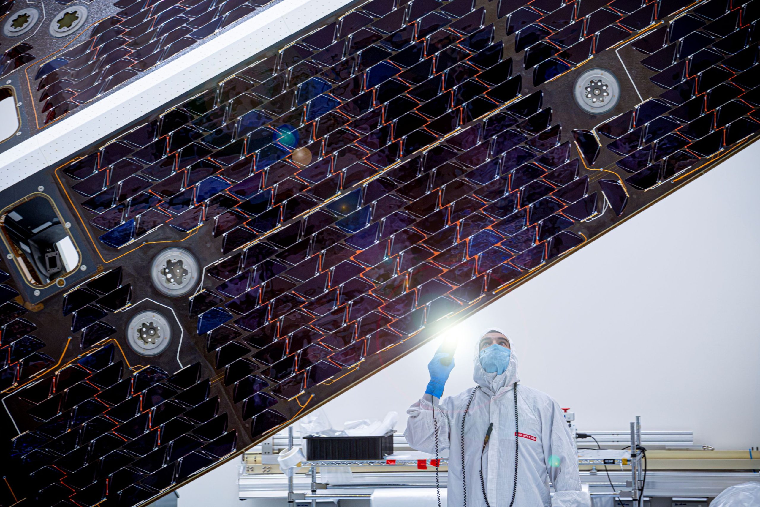 NASA’s Neo Surveyor Sunshade – The large sunshade of NASA’s Near-Earth Object Surveyor mission is inspected by a technician at BAE Systems Space & Mission Systems in Boulder, Colorado, in late July. NASA’s Neo Surveyor Sunshade – The large sunshade of NASA’s Near-Earth Object Surveyor mission is inspected by a technician at BAE Systems Space & Mission Systems in Boulder, Colorado, in late July.